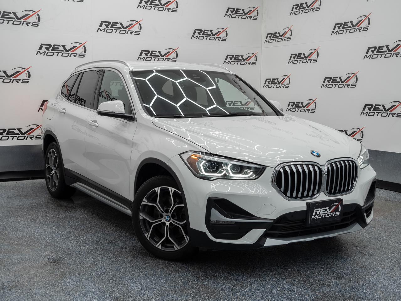 2020 BMW X1 xDrive | Low Mileage | Leather Interior | Apple CarPlay<br/> <br/> Alpine White Exterior | Black Interior | 2.0L TwinPower Turbocharged Inline‑4 Engine | 228 Horsepower | 258 lb‑ft of Torque | 8‑Speed Steptronic Automatic Transmission | xDrive All‑Wheel Drive | Drive Mode Select | Heated Front Seats | Leather / Premium Leatherette Seating | BMW iDrive Infotainment System | 8.8‑Inch Central Display | Apple CarPlay Compatibility | Dual‑Zone Automatic Climate Control | Power Liftgate | Keyless Entry & Push‑Button Start | LED Headlights | Rain‑Sensing Wipers | Rearview Camera | Parking Sensors | Dynamic Stability Control | and much more <br/> <br/> <br/> Features Include: <br/> Heated Front Seats | Black Interior | BMW iDrive System | Apple CarPlay | Dual‑Zone Climate Control | Power Liftgate | Push‑Button Start | Keyless Entry | LED Headlights | Rain‑Sensing Wipers | Drive Mode Select (Eco / Comfort / Sport) | Rearview Camera | Parking Sensors | Split‑Folding Rear Seats <br/> <br/> <br/> The 2020 BMW X1 xDrive delivers sporty performance, premium comfort, and everyday versatility in a compact luxury SUV package. <br/> <br/> <br/> Key Features <br/> <br/> <br/> Clean & Modern Design <br/> Finished in Alpine White, the BMW X1 presents a sharp, athletic look with BMW’s signature kidney grille, sculpted body lines, and available LED lighting. Its compact size makes it ideal for city driving while maintaining classic BMW road presence. <br/> <br/> <br/> Refined Black Interior Experience <br/> Inside, the black interior offers a clean and upscale environment. Thoughtful ergonomics, high‑quality materials, and heated front seats ensure comfort for both daily commuting and longer journeys. <br/> <br/> <br/> Intelligent BMW Technology <br/> The BMW iDrive infotainment system provides seamless access to navigation, media, and vehicle settings through an intuitive central display. Apple CarPlay compatibility keeps you connected while maintaining a driver‑focused layout. <br/> <br/> <br/> Turbocharged Performance with xDrive Confidence <br/> Powered by a 2.0L turbocharged inline‑4, the X1 produces 228 horsepower and 258 lb‑ft of torque, delivering smooth acceleration and responsive performance. Paired with an 8‑speed automatic transmission and BMW’s intelligent xDrive all‑wheel drive, the X1 accelerates from 0–60 mph in approximately 6.3 seconds while maintaining excellent stability in all weather conditions. <br/> <br/> <br/> Advanced Safety & Stability <br/> Standard safety features include dynamic stability control, traction control, rearview camera, and parking sensors—enhancing confidence whether navigating tight city streets or open highways. <br/> <br/> <br/> Practical Luxury for Everyday Life <br/> With seating for five, a flexible cargo area, and BMW’s signature driving dynamics, the X1 offers impressive versatility without compromising luxury or performance—making it an ideal daily driver and weekend companion. <br/> <br/> <br/> The 2020 BMW X1 xDrive28i is more than a compact SUV—it’s a refined blend of BMW performance, premium comfort, and everyday usability. With its white exterior, black interior, turbocharged power, and xDrive all‑wheel drive, this X1 delivers confidence and clarity in every drive. <br/> <br/> <br/> This vehicle has travelled 23,541 Kms. <br/> <br/> <br/> *** NO additional fees except for taxes and licensing! *** <br/> <br/> <br/> *** 100-point inspection on all our vehicles & always detailed inside and out *** <br/> <br/> <br/> RevMotors is at your service to ensure you find the right car for YOU. Even if we do not have it in our inventory, we are more than happy to find you the vehicle that you are looking for. Give us a call at 613-791-3000 or visit us online at www.revmotors.ca <br/> <br/> <br/> Ça nous donnera du plaisir de vous servir en Français aussi! <br/> <br/> <br/> CERTIFICATION * As per OMVIC regulations - this vehicle is being sold AS-IS and is not considered road worthy - Certification / Safety is available for $699. <br/> FINANCING AVAILABLE * RevMotors offers competitive finance rates through many of the major banks. Should you feel like youve had credit issues in the past, we have various financing solutions to get you on the road. We accept No Credit - New Credit - Bad Credit - Bankruptcy - Students and more!! Please keep in mind the default loan structure found on the vehicle page is a template. The exact rate and terms that a vehicle qualifies for may differ. All quotes are subject to lender approval. <br/> EXTENDED WARRANTY * For your peace of mind, if one of our used vehicles is no longer covered under the manufacturer’s warranty, RevMotors will provide you with a 6 month / 6000KMS Limited Powertrain Warranty. You always have the options to upgrade to more comprehensive coverage as well. Well be more than happy to review the options and chose the coverage thats right for you! <br/> TRADES * Do you have a Trade-in? We offer competitive trade in offers for your current vehicle! <br/> SHIPPING * We can ship anywhere across Canada. Give us a call for a quote and we will be happy to help! <br/> <br/> <br/> Buy with confidence knowing that we always have your best interests in mind! <br/>