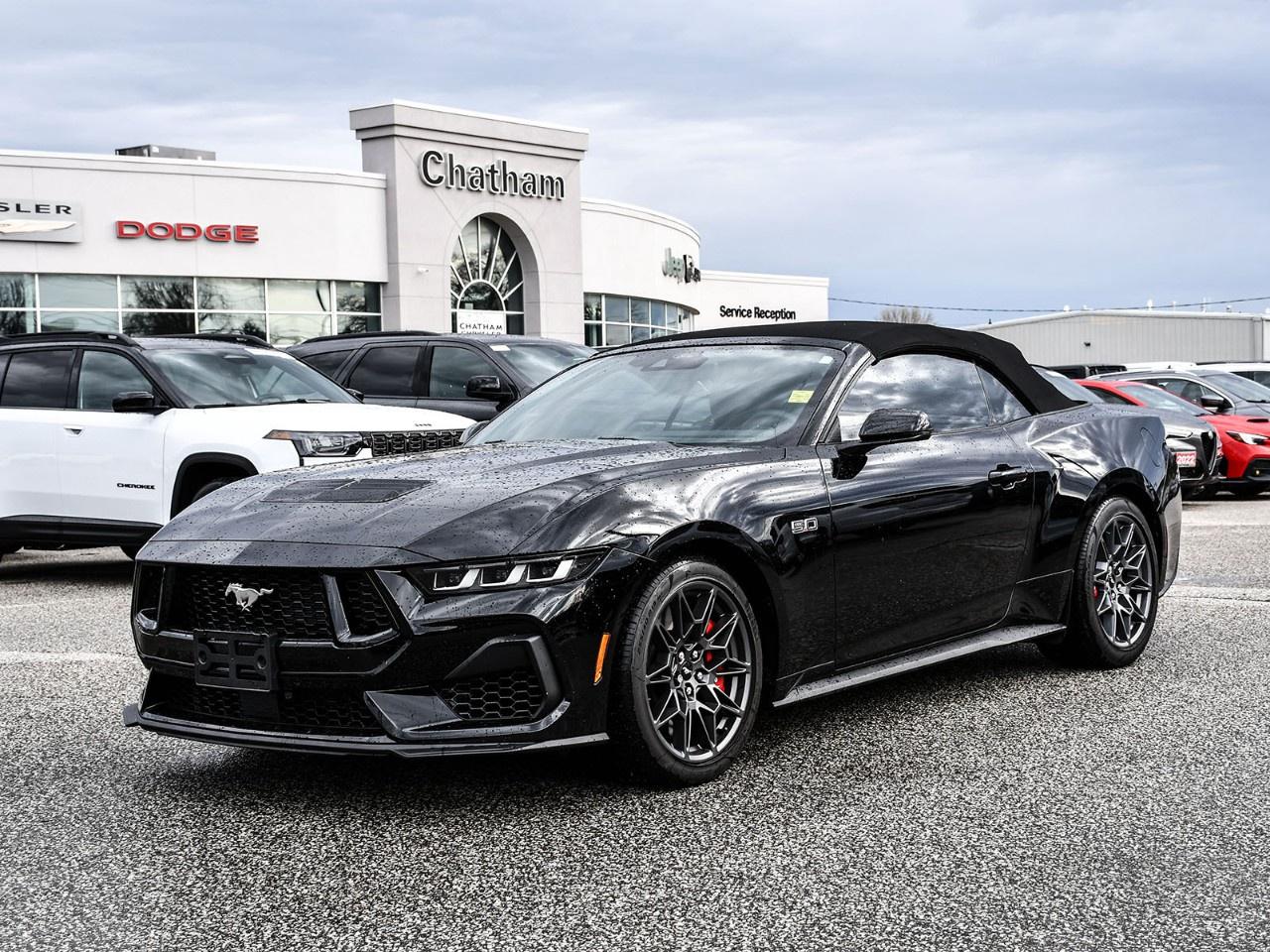 2024 Ford Mustang 2D Convertible GT Premium Shadow Black 19''' Branded Brake System w/Performance Linings, 4-Wheel Disc Brakes, ABS brakes, Accent Stitched Centre Console Lid, Active Anti-Theft System, Air Conditioning, Alloy wheels, Auto High-beam Headlights, Auto-dimming Rear-View mirror, Automatic temperature control, B&O Sound System by Bang & Olufsen, B&O Sound System by Bang & Olufsen w/HD Radio (DISC), Brake assist, Bumpers: body-colour, Delay-off headlights, Driver Seat Memory w/3 Settings, Dual front impact airbags, Dual front side impact airbags, Ebony Black Grille, Electric Hand-Operated Parking Brake (Drift Brake), Electronic Stability Control, Equipment Group 401A High Package, Exterior Parking Camera Rear, Four wheel independent suspension, Front anti-roll bar, Front Bucket Seats, Front dual zone A/C, Front reading lights, Front Towing Hooks, Fully automatic headlights, GT Performance Package, Heated door mirrors, Heated front seats, Heated steering wheel, Heavy-Duty Front Springs, Illuminated entry, Knee airbag, Leather Shift Knob, Leather steering wheel, Leather-Trimmed Climate-Controlled Bucket Seats, Locking Centre Console, MagneRide Damping System, Occupant sensing airbag, Passenger vanity mirror, Power convertible roof, Power door mirrors, Power driver seat, Power passenger seat, Rain sensing wipers, Rear anti-roll bar, Rear Parking Sensors, Rear window defroster, Red Painted Brake Calipers w/White Logo, Remote keyless entry, Security Package, Security system, SiriusXM w/360L, Speed-sensing steering, Speed-Sensitive Wipers, Spoiler, Sport steering wheel, Steering wheel mounted audio controls, SYNC 4.0 QNX, Telescoping steering wheel, Tilt steering wheel, TORSEN Differential, Traction control, Turn signal indicator mirrors, Variably intermittent wipers, Ventilated front seats, Wheels: 19''' x 9''' Fr & 19''' x 9.5''' Rr. RWD 5.0L V8 Ti-VCT 10-Speed Automatic<br /><br /><br />Here at Chatham Chrysler, our Financial Services Department is dedicated to offering the service that you deserve. We are experienced with all levels of credit and are looking forward to sitting down with you. Chatham Chrysler Proudly serves customers from London, Ridgetown, Thamesville, Wallaceburg, Chatham, Tilbury, Essex, LaSalle, Amherstburg and Windsor with no distance being ever too far! At Chatham Chrysler, WE CAN DO IT!