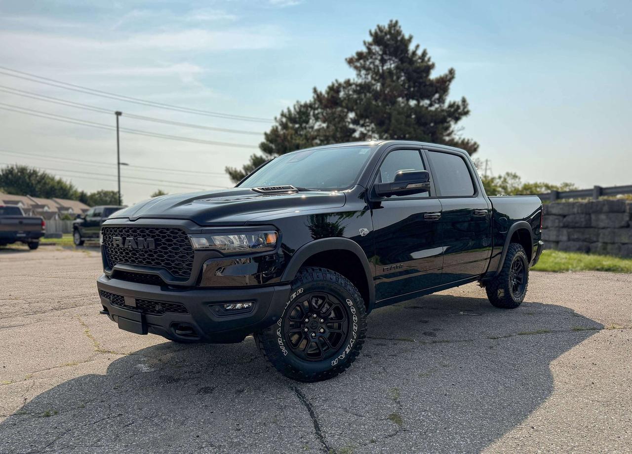 NAVIGATION, BACKUP CAMERA,  BLUETOOTH, HEATED SEATS. HEATED STEERING AND MORE !!!

Bold and unmistakable, our 2026 RAM 1500 Rebel Crew Cab 4X4 in Diamond Black Crystal Pearl stands out with aggressive design and off-road capability. Powered by a 5.7 Litre HEMI eTorque V8 and a 48V Mild-Hybrid system offering 395hp paired with an 8 Speed Automatic transmission engineered for off-road domination. A raised ride height, performance shocks, and a shift-on-demand transfer case can take this Four Wheel Drive truck further down the trail, and it achieves approximately 9.8L/100km on the highway. Our fierce and stylish RAM features LED lighting, fog lamps, a sport performance hood, bold graphics, lower two-tone paint, alloy wheels, off-road fender flares, and robust skid plates.

Our Rebel cabin is ready for rough terrain thanks to its heated cloth front seats, eight-way power for the driver, a heated-wrapped steering wheel, dual-zone automatic climate control, 12V/115V outlets, a power rear window, and remote start. Off-Road Info Pages enhance the infotainment system, which bundles a 12-inch driver display, 12-inch touchscreen, full-color navigation, WiFi compatibility, Android Auto&reg;/Apple CarPlay&reg;, Bluetooth&reg;, voice control, and nine-speaker audio.

For safetys sake, RAM supplies front/rear auto braking, blind-spot monitoring, adaptive cruise control, active lane management, trailer sway damping, hill-start assistance, and more. Committed to truck leadership, our 1500 Rebel is a compelling choice! Save this Page and Call for Availability. We Know You Will Enjoy Your Test Drive Towards Ownership! 

Bustard Chrysler prides ourselves on our expansive used car inventory. We have over 100 pre-owned units in stock of all makes and models, with the largest selection of pre-owned Chrysler, Dodge, Jeep, and RAM products in the tri-cities. Our used inventory is hand-selected and we only sell the best vehicles, for a fair price. We use a market-based pricing system so that you can be confident youre getting the best deal. With over 25 years of financing experience, our team is committed to getting you approved - whether you have good credit, bad credit, or no credit! We strive to be 100% transparent, and we stand behind the products we sell. For your peace of mind, we offer a 3 day/250 km exchange as well as a 30-day limited warranty on all certified used vehicles.