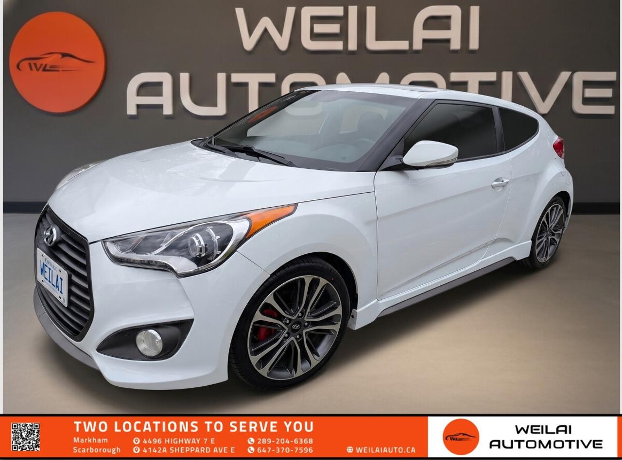 1.6L Turbocharged Engine | Panoramic Sunroof | Heated Leather Seats | Dimension Premium Audio | Unique Asymmetrical 3-Door Design | Low credit? No credit? Established Credit? We accept ALL!!! - Contact Us Today!Test Drive the 2016 Hyundai Veloster Turbo Today! The 2016 Hyundai Veloster Turbo stands out from the crowd with its innovative 3-door design, sporty performance, and exceptional value. Engineered for driving enthusiasts, this hatchback delivers a thrilling ride with its turbocharged engine while offering a comfortable and feature-packed cabin. Whether you are commuting in the city or taking a weekend road trip, the Veloster Turbo provides the perfect blend of style, agility, and modern technology tailored for the Canadian climate. <br/> Performance: <br/> Engine: 1.6L Turbocharged GDI 4-Cylinder <br/> Horsepower: 201 hp <br/> Torque: 195 lb-ft <br/> Transmission: 7-Speed EcoShift Dual Clutch Automatic <br/> Drivetrain: FWD <br/> Exterior: <br/> Unique asymmetrical 3-door body design with hidden rear passenger door handle <br/> 18-inch alloy wheels with a distinctive machined finish <br/> Projector headlights with stylish LED accents <br/> Expansive panoramic sunroof <br/> Sporty dual center exhaust outlets <br/> Interior: <br/> Premium leather seating surfaces with Turbo embroidery <br/> Heated front sport seats for cold Canadian winters <br/> Heated leather-wrapped steering wheel <br/> Sporty aluminum alloy pedals <br/> 60/40 split-folding rear seats for versatile cargo space <br/> Technology: <br/> 7-inch high-resolution touchscreen navigation and infotainment system <br/> Dimension premium audio system with 8 speakers and a subwoofer <br/> Bluetooth hands-free phone system with voice recognition <br/> Proximity keyless entry with push-button start <br/> SiriusXM satellite radio capability with USB and auxiliary inputs <br/> Safety: <br/> Rearview camera with dynamic parking guidelines <br/> Rear parking assist sensors <br/> Electronic Stability Control with Traction Control System <br/> Anti-lock Braking System with Electronic Brake-force Distribution <br/> Six standard airbags including dual front, front seat-mounted side, and side curtain <br/> Approximate Fuel Efficiency: <br/> City: 9.7 L/100 km <br/> Highway: 7.0 L/100 km! <br/> Our hot inventory is moving faster than ever, and a highly sought-after vehicle like this 2016 Hyundai Veloster Turbo will not stay on our lot for long. Do not miss your chance to own this incredible, sporty hatchback. Visit Weilai Automotive Inc. in Markham today to experience the thrill for yourself. Call us now to schedule your exclusive test drive and secure this vehicle before someone else drives it home! <br/> <br/> <br/> FINANCING: At Weilai Automotive Inc., were all about giving everyone a fair shot at owning a quality vehicle, no matter their credit history. Whether youre grappling with credit challenges or have a stellar credit record, we have financing options that cater to you. Your specific financing terms will depend on various factors, including your credit rating. For a personalized finance consultation, a signed consent form is needed. Reach out to schedule your appointment today. <br/> WEILAI CERTIFIED PRE-OWNED PROGRAM:* <br/> Full Detailing Package <br/> Comprehensive Certification Package <br/> Safety Certification <br/> Financing Available <br/> Extended Warranty Available <br/> Available for only $899 <br/> *Weilai Certified Pre-Owned Program includes: Full interior detailing, full exterior detailing, meticulous vehicle reconditioning. A comprehensive 60-point safety inspection with additional standards. For example, tire and brake treads must be a minimum of 3.5 mm which is 233% of the Ontario standard of 1.5 mm. Access to a large network of lenders to give you the best approval guaranteed. Option to extend the warranty for up to an additional 6 years for an additional fee. <br/> CARFAX REPORT: We believe in full transparency. All vehicles come with a FREE Carfax report. Please visit our listing on weilaiauto.ca or autotrader.ca to obtain your free Carfax report. <br/> CONTACT NOW: We welcome customers from all over the GTA, including Markham, Scarborough, Barrie, Stouffville, Toronto, Richmond Hill, East Gwillimbury, Aurora, North York, East York, Whitby, Brampton, and the surrounding area. Ready to take the next step? Book an appointment, get more info, or get in touch by calling 647-370-7596 or emailing us at scmanagers@weilaiauto.ca. <br/> <br/> <br/> FEE DISCLOSURE: Price does not include safety certification, HST, or licensing fees. Safety certification available, see the Weilai Certified Pre-Owned Program for details. <br/> FINANCE SPECIAL PRICE ONLY: Pricing is based on financing. The listed price includes a $1,000 finance rebate. Choosing an alternative payment method may disqualify this rebate. <br/> VEHICLE CONDITION: The vehicle has been inspected and reconditioned to a premium pre-owned condition and is ready to be test-driven. However, to comply with OMVICs disclosure requirements, please note that this unit is not currently drivable and not certified until it undergoes safety certification. <br/> DISCLAIMERS: Please note that these details are based on the typical specifications for a given year, make, and model, and actual features may vary for the specific VIN provided. The descriptions above and the contents on this vehicle detail page are generated using AI and VIN decoders, which may contain inaccuracies. They are intended for reference only and may not be entirely reliable. Always check the vehicles actual specifications and refer to the owners manual for the most precise and up-to-date information. While Weilai Automotive Inc. strives to provide accurate information, we will not be responsible for any mistakes made on this page. <br/>