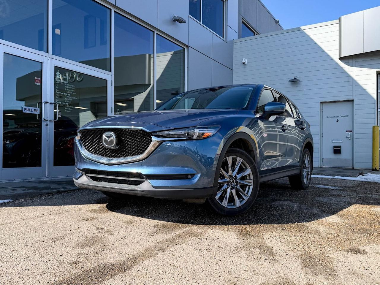 Experience the perfect blend of performance, luxury, and technology with this pre-owned 2020 Mazda CX-5 GT w/Turbo AWD. Powered by a turbocharged 2.5L SKYACTIV-G engine paired with a smooth 6-speed automatic transmission, this SUV delivers exhilarating performance and confident all-wheel drive handling. Inside, enjoy premium comfort with heated and ventilated leather front seats, dual-zone climate control, and advanced tech including Bose premium sound, a navigation system, and an 8-inch touchscreen display. Safety is top-notch thanks to features like blind spot monitoring, lane departure prevention, and forward collision mitigation. With stylish 19-inch alloy wheels, LED adaptive headlights, and a panoramic sunroof, this CX-5 GT stands out on every journey. Ready for your next adventure? Come test drive this exceptional Mazda today!Go Mazda is an AMVIC licensed businessClean CarFax