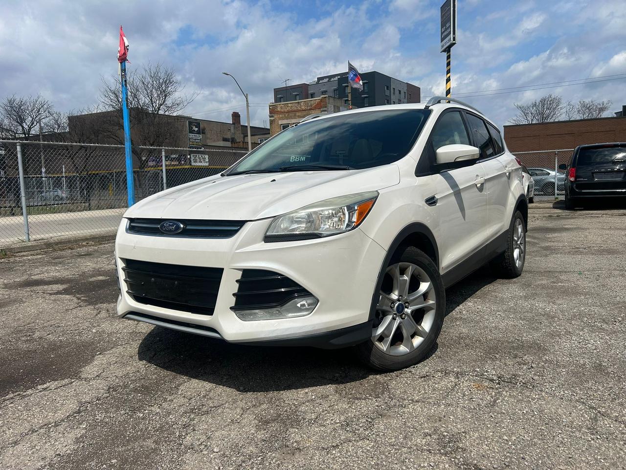 <p><strong>2014 Ford Escape Titanium &ndash; Fully Loaded &bull; AWD &bull; Clean & Smooth Drive</strong></p><p>Discover comfort, capability, and premium features in this well‑equipped <strong>Ford Escape Titanium</strong>. This SUV delivers a refined drive, excellent fuel efficiency, and all the top‑tier options the Titanium package is known for.</p><h3><strong>Key Features</strong></h3><ul><li><p><strong>2.0L EcoBoost Engine</strong> &ndash; strong, efficient, and reliable</p></li><li><p><strong>All‑Wheel Drive</strong> &ndash; confident handling in all weather</p></li><li><p><strong>Leather Interior</strong> &ndash; clean, comfortable, and well‑kept</p></li><li><p><strong>Heated Front Seats</strong></p></li><li><p><strong>Sony Premium Sound System</strong></p></li><li><p><strong>Navigation System</strong></p></li><li><p><strong>Backup Camera + Parking Sensors</strong></p></li><li><p><strong>Panoramic Sunroof</strong></p></li><li><p><strong>Power Tailgate</strong></p></li><li><p><strong>Remote Start</strong></p></li><li><p><strong>Keyless Entry + Push‑Button Start</strong></p></li><li><p><strong>Bluetooth, USB, AUX</strong></p></li></ul><h3><strong>Condition & Drive</strong></h3><p>Runs and drives great with smooth acceleration and responsive steering. Interior and exterior are in solid shape for the year. A reliable, comfortable SUV ready for daily use.</p><h3><strong>Why Buy This Escape?</strong></h3><p>Titanium trim gives you luxury features at an affordable price. Perfect for commuting, family use, or long trips.</p><p><strong>Located in Hamilton.</strong> <strong>Financing options available.</strong> <strong>Trade‑ins welcome.</strong></p>