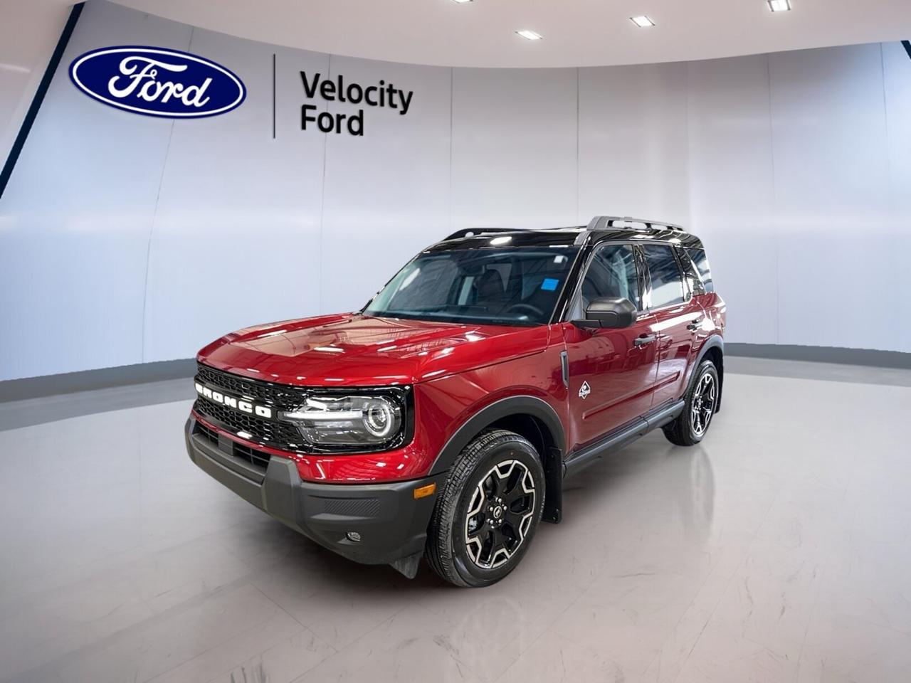 Discover a fresh take on everyday adventure with this brand new 2026 Ford Bronco Sport Outer Banks 4x4 at Velocity Ford in Moose Jaw. Finished in red with a black interior, this four-door SUV blends smart comfort, useful technology, and sure-footed four-wheel drive for life in every season.

Built for drivers who want confidence on city streets and back roads alike, the 2026 Ford Bronco Sport Outer Banks 4x4 pairs a 1.5-litre unleaded engine with an 8-speed automatic transmission. It delivers smooth response, practical efficiency, and the added control of 4WD when road conditions change.

FEATURES OF THE Bronco Sport Outer Banks 4x4

»» Red exterior with bold SUV presence
»» Black interior with upscale everyday comfort
»» Four-wheel drive for added year-round traction
»» Eight-speed automatic for smooth shifting

ADVANCED SAFETY FEATURES

»» Backup camera helps with reversing visibility
»» Blind spot monitor adds lane-change confidence
»» Lane departure warning supports safer travel
»» Side and head airbags add protection

PERFORMANCE AND EFFICIENCY

»» 1.5-litre unleaded engine balances power and economy
»» 8-speed automatic supports smooth highway cruising
»» Four-wheel drive improves traction on rough roads
»» Power steering helps easy daily manoeuvres

COMFORT AND CONVENIENCE

»» Heated front seats for cold mornings
»» Dual-zone climate control improves cabin comfort
»» Remote starter adds everyday convenience
»» Power seats with memory driver settings

TECHNONOLGY AND CONNECTIVITY

»» Bluetooth integration supports hands-free phone access
»» WiFi hotspot keeps passengers better connected
»» Satellite radio expands in-cabin entertainment choices
»» Steering wheel audio controls simplify use

CARGO SPACE

»» Rear trunk access makes loading simple
»» Four-door layout helps passenger entry ease
»» Flexible SUV design suits daily errands
»» Cargo area supports active lifestyles well

The cabin of this 2026 Ford Bronco Sport Outer Banks 4x4 is designed to make each trip easier. Heated mirrors, electric mirrors, power windows, automatic climate control, and an auto-dimming rearview mirror all work together to improve daily comfort in changing Prairie weather.

Convenience features are well chosen for busy drivers. Push button start, automatic door locks, rear window defroster, tinted windows, illuminated vanity mirrors, driver lumbar support, and memory mirrors help make every drive feel more relaxed and more refined.

Lighting and visibility are also strong points in this 2026 Ford Bronco Sport Outer Banks 4x4. LED headlamps, fog lights, automatic headlights, and a backup camera help support clear sightlines in low light, poor weather, and crowded parking areas.

WHAT OTHER OWNERS LIKE

»» Easy-to-use controls for everyday driving
»» Confident all-weather traction from four-wheel drive
»» Comfortable ride with useful cabin features
»» Practical size with versatile cargo room

This 2026 Ford Bronco Sport Outer Banks 4x4s VIN is: 3FMCR9CN1TRE37794.