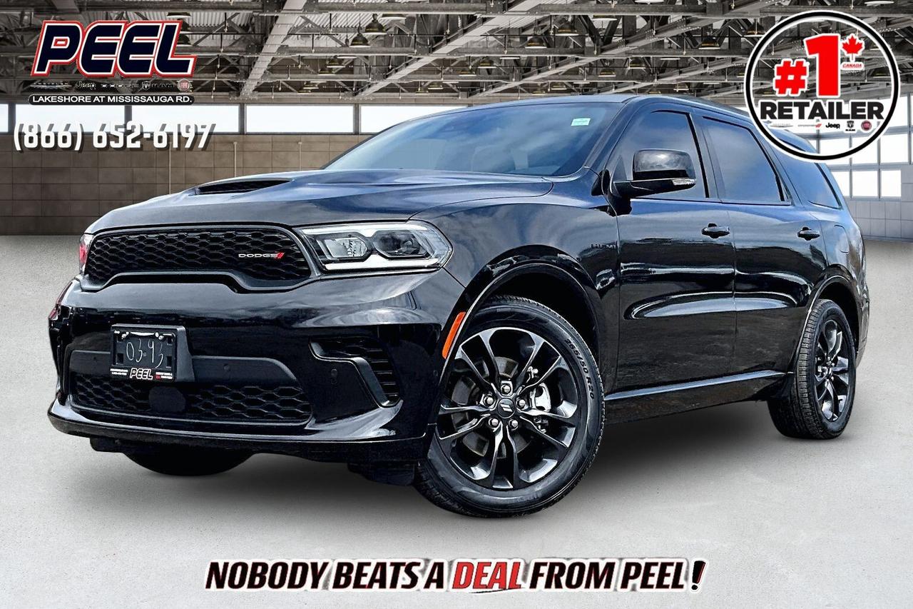 COME SEE WHY NOBODY BEATS A DEAL FROM PEEL! Your Source for ALL make and models used cars and trucks. The True #1 Stellantis Retailer in Ontario for 14 years and running!! (*)

2024 Dodge Durango R/T Plus AWD | 5.7L V8 | DB Black | Blacktop Package | Heated & Ventilated Nappa Leather Seats | 6 Passenger Seating w/ Second Row Captain Chairs | Uconnect 5 10.1" Display w/ Navigation | 19-speaker Harman/Kardon High Performance Audio System | Power Sunroof | Dinamica Suede Headliner | Forged Carbon Fibre Interior Accents | Wireless Apple CarPlay & Android Auto | Wireless Charging | Adaptive Cruise Control | Lane Keep Assist | Forward Collision Warning | Blind Spot Monitoring | Heated Steering Wheel | Remote Start | Power Liftgate | Parking Sensors | Blind Spot Monitoring 

One Owner Clean Carfax

A rare mix of V8 muscle and premium SUV luxury, this 2024 Dodge Durango R/T Plus in DB Black with the Blacktop Package delivers the kind of presence and performance that sets it apart, powered by the 5.7L HEMI V8 producing 360 hp and 390 lb-ft of torque for strong, effortless acceleration and that unmistakable exhaust note. Inside, it feels properly upscale with heated and ventilated Nappa leather seats, a heated steering wheel, second-row captain&rsquo;s chairs for true 6-passenger comfort, and a power sunroof paired with a Dinamica suede headliner and forged carbon fibre interior accents that give it a high-end, performance-inspired finish. The Uconnect 5 system on the 10.1-inch display with navigation, wireless Apple CarPlay and Android Auto, wireless charging, and a 19-speaker Harman Kardon audio system make every drive feel modern and immersive. Safety and driver assistance are fully covered with Adaptive Cruise Control, Lane Keep Assist, Forward Collision Warning, Blind Spot Monitoring, and parking sensors to make daily driving and long trips more relaxed. Finished with a power liftgate for added convenience and the aggressive Blacktop styling, this is the R/T Plus buyers look for, combining V8 power, premium features, and everyday practicality, and with One Owner, Clean Carfax history, it is a standout SUV that delivers on every level.
______________________________________________________

Engage & Explore with Peel Chrysler: Whether youre inquiring about our latest offers or seeking guidance, 1-866-652-6197 connects you directly. Dive deeper online or connect with our team to navigate your automotive journey seamlessly.

WE TAKE ALL TRADES & CREDIT. WE SHIP ANYWHERE IN CANADA! OUR TEAM IS READY TO SERVE YOU 7 DAYS!
______________________________________________________
Our advertised prices are for consumers (i.e end users) only. 

*FREE CarFax (click the link above to check it out at no cost to you!)*

*FULLY CERTIFIED! (Have you seen some of these other dealers stating in their advertisements that certification is an additional fee? NOT HERE! Our certification is already included in our low sale prices to save you more!)

(*) Based on the Eastern Business Center National Ranking reported sales to actual customers, not including demonstrators.
______________________________________________________

Peel Chrysler  A Trusted Destination: Based in Port Credit, Ontario, we proudly serve customers from all corners of Ontario and Canada including Toronto, Oakville, North York, Richmond Hill, Ajax, Hamilton, Niagara Falls, Brampton, Thornhill, Scarborough, Vaughan, London, Windsor, Cambridge, Kitchener, Waterloo, Brantford, Sarnia, Pickering, Huntsville, Milton, Woodbridge, Maple, Aurora, Newmarket, Orangeville, Georgetown, Stouffville, Markham, North Bay, Sudbury, Barrie, Sault Ste. Marie, Parry Sound, Bracebridge, Gravenhurst, Oshawa, Ajax, Kingston, Innisfil and surrounding areas. On our website www.peelchrysler.com, you will find a vast selection of new vehicles including the new and used Ram 1500, 2500 and 3500. Chrysler Grand Caravan, Chrysler Pacifica, Jeep Cherokee, Wrangler and more. All vehicles are priced to sell. We deliver throughout Canada. website or call us 1-866-652-6197. 

Disclaimer Statement: At Peel Chrysler, your satisfaction is our priority. While many pre-owned vehicles originally come with two keys, variations may occur based on trade-ins, and all Peel Chrysler Pre-Owned Vehicles come standard with one key. Any extras provided by the previous owner will be included with your purchase, and additional keys can be bought at the time of sale. Online prices and payments are for finance purchases. Used vehicles that are being financed are subject to a $499 (^$1500 non-prime) financing fee, while cash purchases (certified cheque, bank draft, or wire transfer) on used vehicles have a $2,000 surcharge ( online price + $2,000). Cash purchases of new vehicles only incur applicable taxes and licensing fees, and those priced above $100,000 (including accessories or add-ons) are subject to a federal luxury tax. Optional finance and lease terms are available, and if trading in a vehicle with an outstanding loan balance requiring Peel Chrysler to facilitate the lien payout, a Lien Payout Fee of $349 applies. Prices, rates, and payments are subject to change without notice. While we strive for accuracy, occasional technical or human errors may occur, so we encourage verifying all vehicle details, including features, options, materials, and specifications, with a Peel Chrysler representative by contacting us or visiting our dealership. Experience seamless convenience with our nationwide delivery options. Visit our website or contact us for more details.