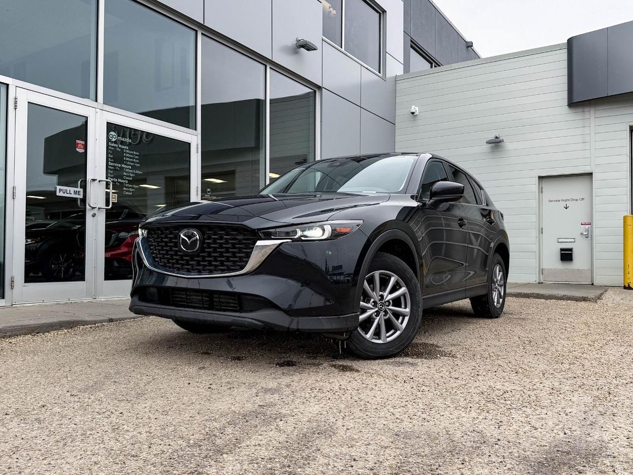 Discover confidence and style with this pre-owned 2022 Mazda CX-5 GX AWD in sleek black! Powered by a responsive 2.5L SKYACTIV-G engine and smooth 6-speed automatic transmission, this SUV seamlessly blends performance with efficiency. Enjoy all-season traction with automatic full-time AWD and a host of safety features including blind spot warning, lane departure prevention, and forward collision mitigation. Inside, heated front seats and a spacious black cloth interior offer comfort for five passengers, while the 10.2-inch touchscreen with smart device mirroring and steering wheel audio controls keep you connected on the go. With thoughtful conveniences like a rearview camera, power windows, and keyless entry with push-button start, the CX-5 GX is ready for your next adventure. Visit Go Mazda today to test drive this well-equipped, reliable SUV!Go Mazda is an AMVIC licensed business