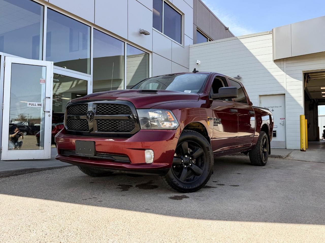 Looking for a tough, stylish, and reliable truck? Check out this pre-owned 2020 Ram 1500 Classic Express 4x4 Crew Cab in striking Red with a rugged Night Edition look. Powered by the dependable 5.7L HEMI V8 and smooth 8-speed automatic, it delivers both power and efficiency for your toughest jobs and daily drives.Enjoy comfort with gray cloth front bench seating, dual-zone A/C, and tech-savvy features like the 8.4 touchscreen with Apple CarPlay and Android Auto. Tow with confidence thanks to the Class IV hitch receiver and advanced trailer wiring harness.With LED bed lighting, remote keyless entry, heated mirrors, and a sport performance hood, this Ram blends functionality with aggressive style. Ready to work hard and look good doing itschedule your test drive today and experience the perfect blend of power and capability!Go Mazda is an AMVIC licensed business.This vehicle has been registered in the province ofOntario and Manitoba and is showing a CarFax incident in the amount of $3,178.41