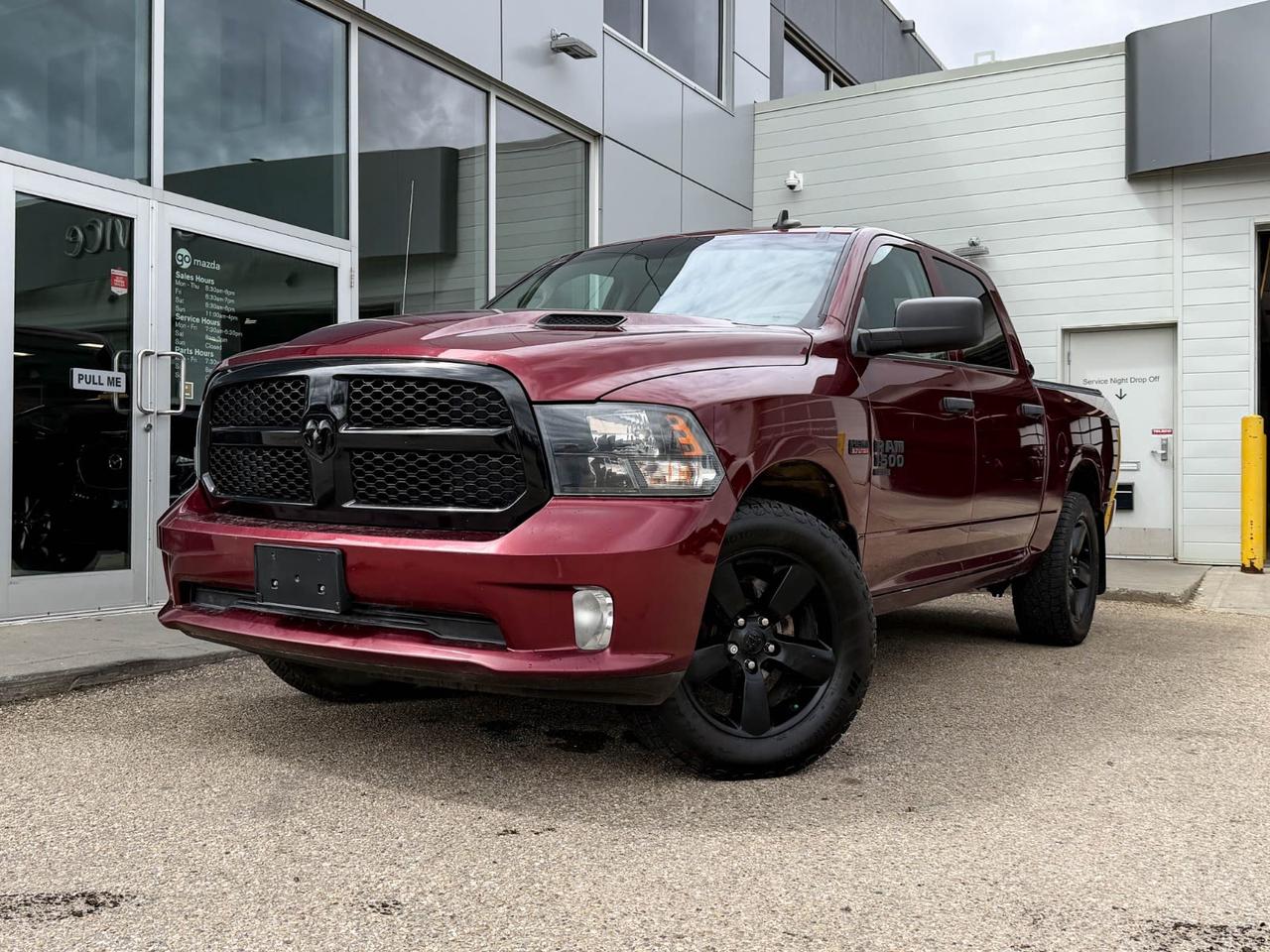 Looking for a tough, stylish, and reliable truck? Check out this pre-owned 2020 Ram 1500 Classic Express 4x4 Crew Cab in striking Red with a rugged Night Edition look. Powered by the dependable 5.7L HEMI V8 and smooth 8-speed automatic, it delivers both power and efficiency for your toughest jobs and daily drives.Enjoy comfort with gray cloth front bench seating, dual-zone A/C, and tech-savvy features like the 8.4 touchscreen with Apple CarPlay and Android Auto. Tow with confidence thanks to the Class IV hitch receiver and advanced trailer wiring harness.With LED bed lighting, remote keyless entry, heated mirrors, and a sport performance hood, this Ram blends functionality with aggressive style. Ready to work hard and look good doing itschedule your test drive today and experience the perfect blend of power and capability!Go Mazda is an AMVIC licensed business.This vehicle has been registered in the province ofOntario and Manitoba and is showing a CarFax incident in the amount of $3,178.41
