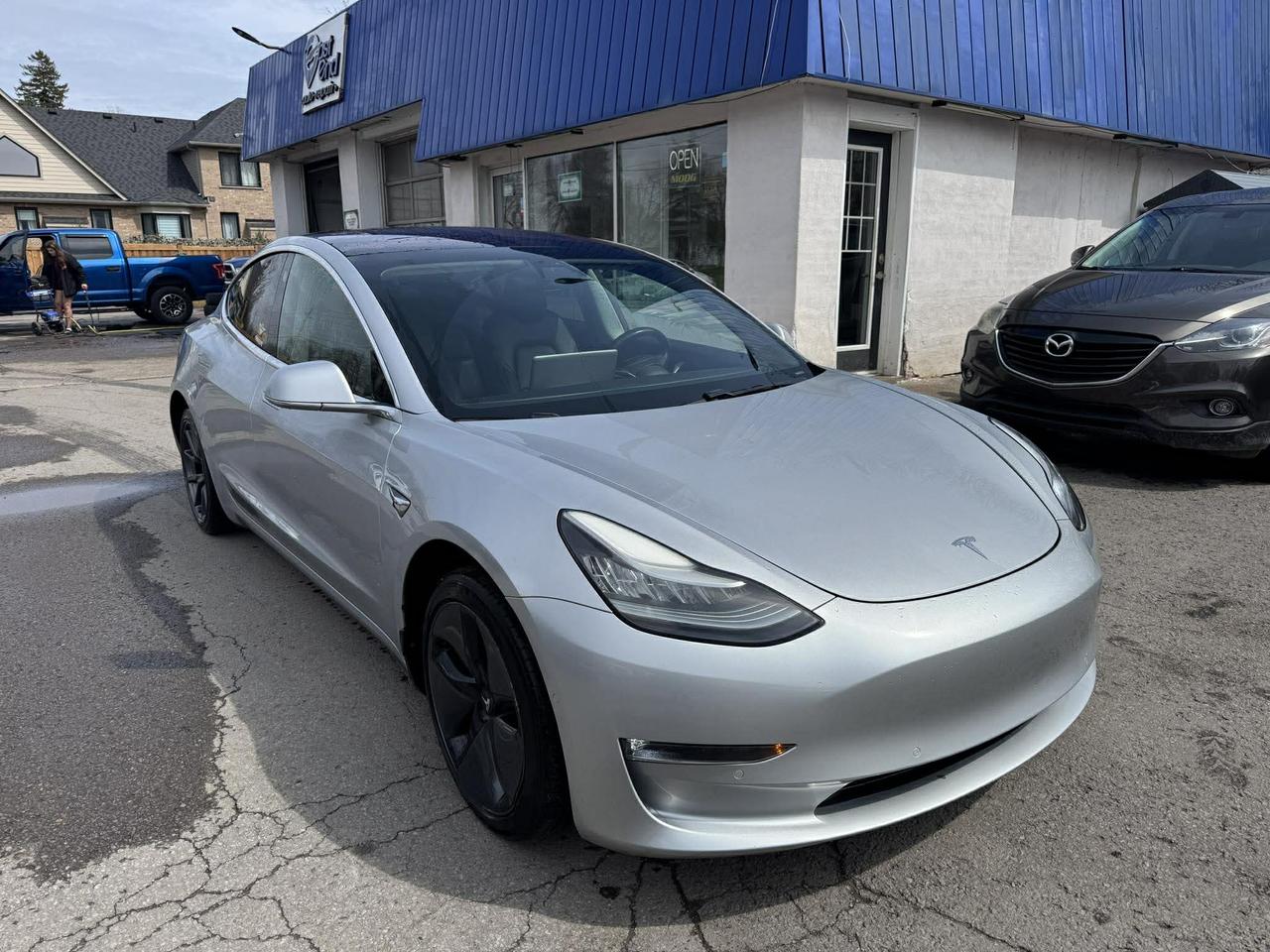 <p>Experience the future of driving with this stunning 2018 Tesla Model 3 Long Range Battery AWD, now available at Mallory Auto! This sleek silver sedan with a sophisticated black interior offers a seamless blend of performance and innovation. With its all-wheel-drive capability and automatic transmission, youll enjoy a smooth, exhilarating ride in any weather condition. This Model 3 has been meticulously maintained and is ready to impress. This all-electric vehicle has 195,263km on the odometer.</p><p>This 2018 Tesla Model 3 Long Range Battery AWD is packed with cutting-edge technology and performance features designed to elevate your driving experience. The Model 3 offers instant torque and impressive range. Get ready to experience the thrill of electric power.</p><p>Here are five standout features of this remarkable Tesla:</p><ul><li><strong>Instant Acceleration:</strong> Experience the exhilarating rush of instant torque that only an electric vehicle can provide.</li><li><strong>All-Wheel Drive Confidence:</strong> Conquer any road condition with the surefootedness of all-wheel drive, ensuring superior traction and control.</li><li><strong>Cutting-Edge Technology:</strong> Enjoy the convenience and innovation of Teslas advanced technology, including a minimalist interior and intuitive touchscreen controls.</li><li><strong>Long-Range Capability:</strong> Drive with confidence, knowing you have the range to tackle your daily commute and weekend adventures.</li><li><strong>Premium Interior:</strong> Relax and enjoy the comfort of a premium black interior.</li></ul><p><strong><em>Powered by AutoIntelligence&trade;</em></strong> Vehicle information has been generated using artificial intelligence and is provided for informational purposes only. While efforts are made to ensure accuracy, please confirm all details directly with the dealer.</p>