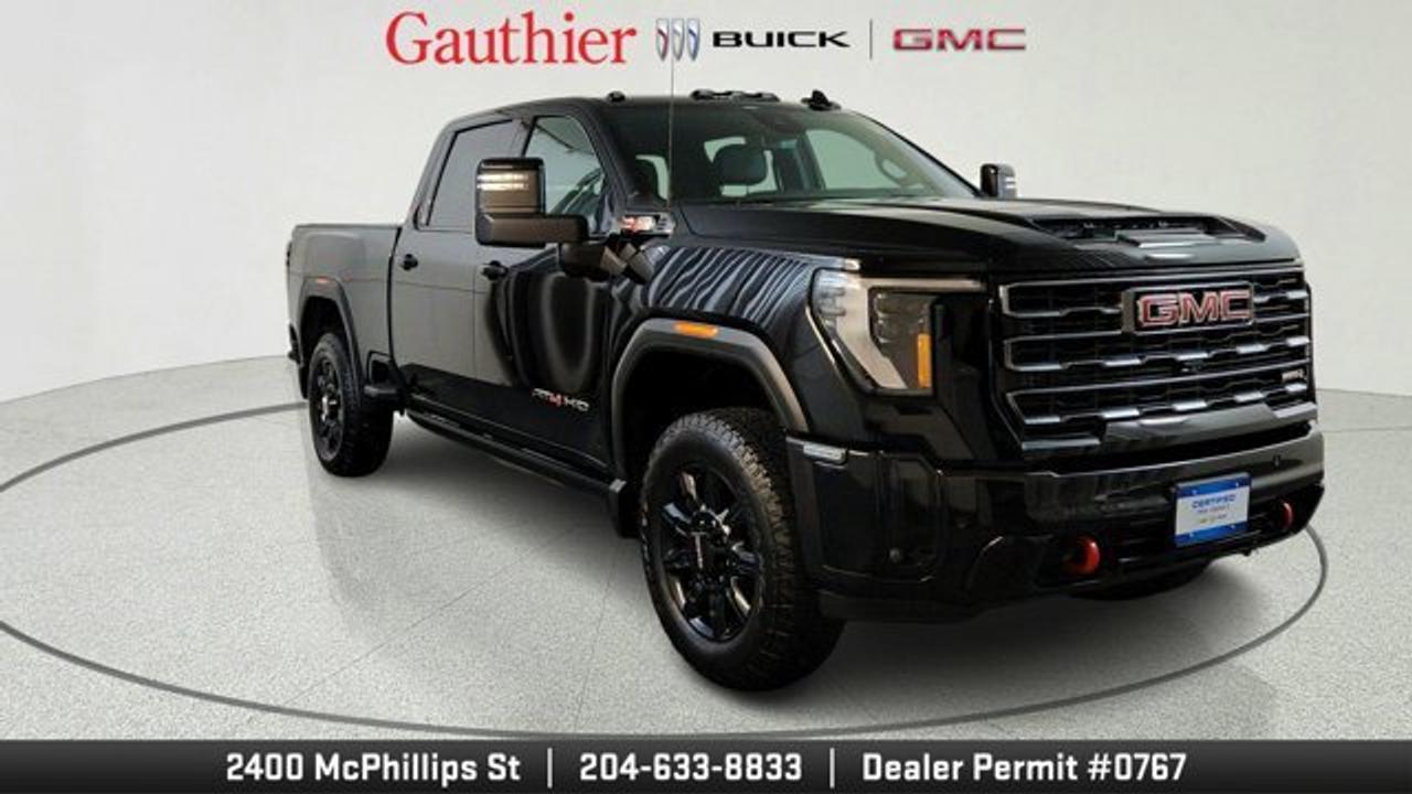 The 2026 GMC Sierra 2500HD AT4 brings serious off-road capability to the heavy-duty truck segment with an off-road suspension package featuring twin-tube Rancho shocks, skid plates, and 20-inch gloss-black aluminum wheels wrapped in available BFGoodrich all-terrain tires. All this comes with refined touches like a Jet Black interior with Kalahari accents and heated, ventilated perforated leather seating. A sunroof allows you to take it all in. Beneath the hood, this AT4 runs with the proven 6.6L Duramax Turbo-Diesel V8 paired with a 10-speed Allison automatic transmission, delivering ample torque and impressive towing capability. It also integrates advanced tech such as HD Surround Vision with up to 14 camera views, Adaptive Cruise Control, and a 15-inch head-up display with off-road inclinometer---blending modern usability with rugged performance. This model also comes with a gooseneck / 5th wheel prep package.