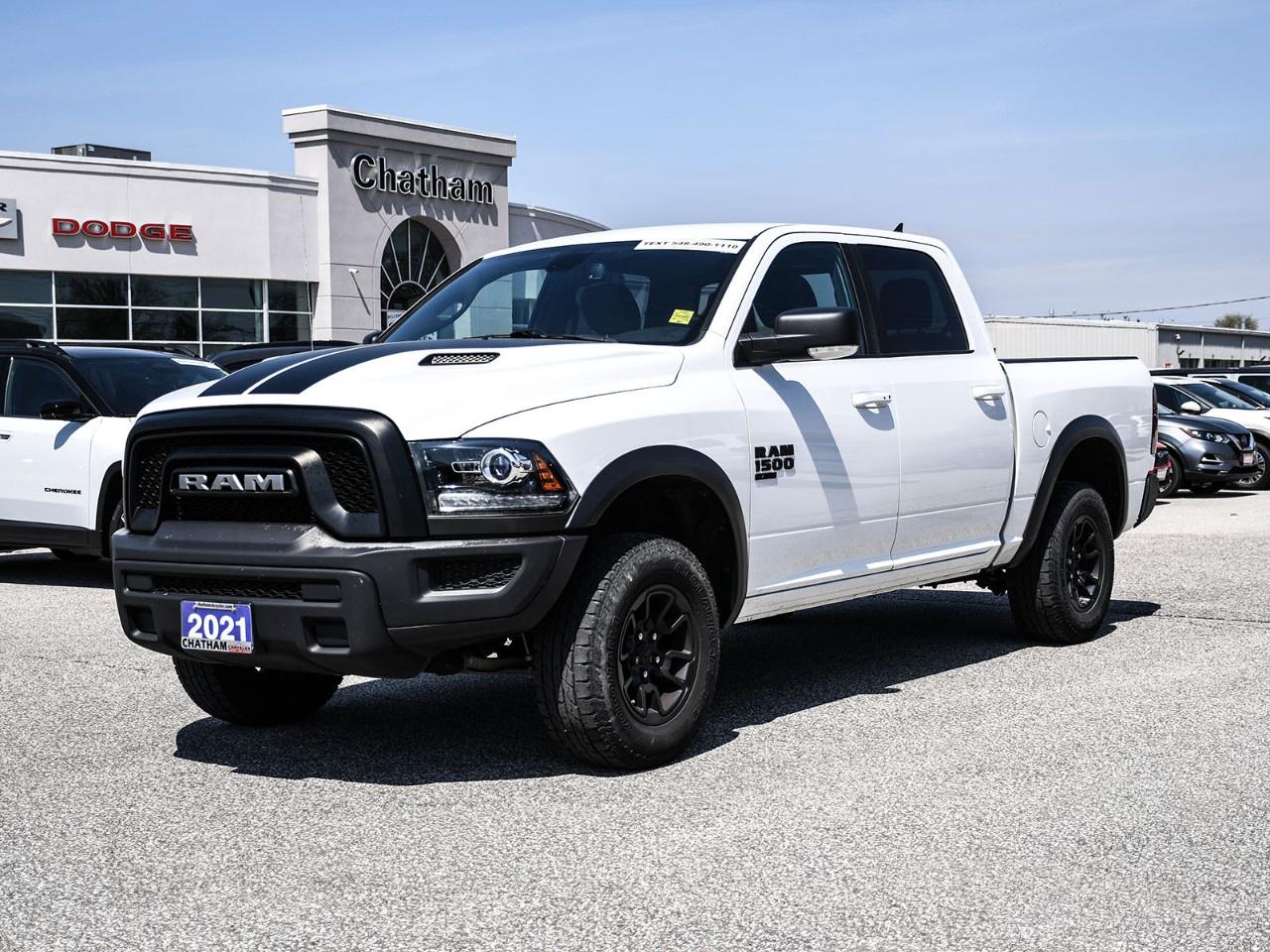 2021 Ram 1500 Classic 4D Crew Cab Warlock Bright White Clearcoat 2nd Row In-Floor Storage Bins, 3.21 Rear Axle Ratio, 4-Wheel Disc Brakes, 6 Speakers, 7''' Colour In-Cluster Display, 8.4''' Touchscreen, A/C w/Dual-Zone Automatic Temperature Control, ABS brakes, Active Grille Shutters, Air Conditioning, Alloy wheels, AM/FM radio, Apple CarPlay Capable, Auto-Dimming Exterior Driver Mirror, Auto-Dimming Rear-View Mirror, Bi-Function Halogen Projector Headlamps, Black 4x4 Badge, Black Door Handles, Black Exterior Badging, Black Grille w/RAM Lettering, Black Headlamp Filler Panel, Black Powder-Coated Front Bumper, Black Powder-Coated Rear Bumper, Black Power Fold Heated Mirrors w/Signals, Black RAM's Head Tailgate Badge, Black Wheel Flares, Block heater, Brake assist, Class IV Hitch Receiver, Cloth Front 40/20/40 Bench Seat, Dedicated Daytime Running Lights, Delay-off headlights, Dual front impact airbags, Dual front side impact airbags, Electronic Stability Control, Electronics Convenience Group, Exterior Mirrors w/Courtesy Lamps, Exterior Mirrors w/Turn Signals, For SiriusXM Info Call 888-539-7474, Front & Rear All-Weather Floor Mats, Front 40/20/40 Split Bench Seat, Front anti-roll bar, Front wheel independent suspension, Front Wheel Well Liners, Fully automatic headlights, Glove Box Lamp, Google Android Auto, GPS Antenna Input, GPS Navigation, Hands-Free Comm w/Bluetooth, HD Radio, Heated door mirrors, Humidity Sensor, Illuminated entry, Leather-Wrapped Steering Wheel, LED Bed Lighting, Luxury Group, Media Hub w/2 USB & Aux Input Jack, Overhead Console/Garage Door Opener, Park-Sense Rear Park Assist System, ParkView Rear Back-Up Camera, Power door mirrors, Power Folding Exterior Mirrors, Push-Button Start, Quick Order Package 29F Warlock, Radio: Uconnect 4C Nav w/8.4''' Display, Radio: Uconnect 4C w/8.4''' Display, Rear anti-roll bar, Rear Dome Lamp w/On/Off Switch, Rear Heavy-Duty Shock Absorbers, Remote Proximity Keyless Entry, Remote Start & Security Alarm Group, Remote Start System, Security Alarm, Semi-Gloss Black Wheel Centre Hub, SiriusXM Satellite Radio, SiriusXM Traffic, SiriusXM Travel Link, Sport Performance Hood, Sport Tail Lamps, Steering Wheel-Mounted Audio Controls, Sun Visors w/Illuminated Vanity Mirrors, Technology Package I, Traction control, Universal Garage Door Opener, USB Mobile Projection, Warlock All Terrain Package, Warlock Interior Accents, Warlock Package, Wheel Centre Hub, Wheels: 20''' x 9''' Black Aluminum. Odometer is 16590 kilometers below market average! 4WD Pentastar 3.6L V6 VVT 8-Speed Automatic<br /><br /><br />Here at Chatham Chrysler, our Financial Services Department is dedicated to offering the service that you deserve. We are experienced with all levels of credit and are looking forward to sitting down with you. Chatham Chrysler Proudly serves customers from London, Ridgetown, Thamesville, Wallaceburg, Chatham, Tilbury, Essex, LaSalle, Amherstburg and Windsor with no distance being ever too far! At Chatham Chrysler, WE CAN DO IT!