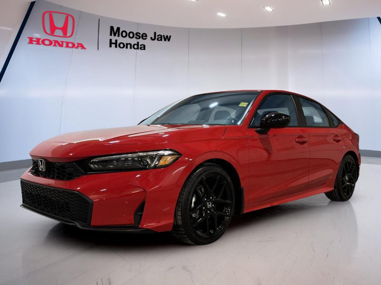 Discover a fresh take on daily driving with the brand new 2026 Honda Civic Sedan Sport at Moose Jaw Honda in Moose Jaw. Finished in red with a black interior, this sedan blends clean design, smart engineering, and everyday practicality. Its 2.0-litre 4-cylinder engine and Continuously Variable Transmission help deliver smooth, confident performance for city streets and highway travel.

FEATURES OF THE Civic Sedan Sport

»» Red exterior adds sporty road presence
»» Black interior keeps cabin clean, modern
»» 2.0-litre four-cylinder engine delivers smooth response
»» CVT supports easy everyday driving

ADVANCED SAFETY FEATURES

»» Honda Sensing suite supports safer daily travel
»» Collision mitigation braking helps reduce impact
»» Lane keeping assist supports highway confidence
»» Road departure mitigation adds extra awareness

PERFORMANCE AND EFFICIENCY

»» 2.0-litre engine balances power and efficiency
»» Continuously Variable Transmission shifts with smoothness
»» Front-wheel drive supports predictable road manners
»» Dual-VTC design helps optimize engine response

COMFORT AND CONVENIENCE

»» Four-door sedan layout aids easy entry
»» Spacious cabin supports daily commuting comfort
»» Clear driving position improves outward visibility
»» Practical design suits work or weekend

TECHNONOLGY AND CONNECTIVITY

»» Driver-focused layout keeps controls within reach
»» Modern instrument display presents key information
»» Easy interface supports simple daily operation
»» Useful cabin technology enhances driving convenience

CARGO SPACE

»» Sedan trunk handles groceries and gear
»» Rear seat area supports passenger flexibility
»» Wide opening helps everyday loading ease
»» Practical storage suits busy lifestyles well

WHAT OTHER OWNERS LIKE

»» Smooth ride quality for daily commutes
»» Excellent fuel economy in real driving
»» Easy controls and simple cabin layout
»» Strong value with trusted Honda durability

The 2026 Honda Civic Sedan Sport is built for drivers who want comfort, efficiency, and confidence in one well-rounded package. Its front-wheel-drive layout gives it a balanced feel in changing Prairie conditions, while the responsive 2.0-litre engine delivers dependable power without making everyday driving feel complicated.

Inside, the 2026 Honda Civic Sedan Sport offers a cabin that feels modern and functional. The black interior gives the space a sharp look, while the sedan body style provides practical room for passengers and day-to-day cargo. It is a smart choice for commuting, errands, and weekend plans around Moose Jaw and beyond.

This brand new 2026 Honda Civic Sedan Sport is ready to bring Honda quality and long-term value to your driveway. With its red exterior, efficient powertrain, and proven compact sedan design, it stands out as a practical and enjoyable new vehicle for drivers who want style, simplicity, and confidence every time they head out.

This 2026 Honda Civic Sedan Sports VIN is: 2HGFE2F56TH109638.<p>Discover a fresh take on daily driving with the brand new 2026 Honda Civic Sedan Sport at Moose Jaw Honda in Moose Jaw. Finished in red with a black interior</p>
<p> and everyday practicality. Its 2.0-litre 4-cylinder engine and Continuously Variable Transmission help deliver smooth</p>
<p> confident performance for city streets and highway travel.

FEATURES OF THE Civic Sedan Sport

»» Red exterior adds sporty road presence
»» Black interior keeps cabin clean</p>
<p> modern
»» 2.0-litre four-cylinder engine delivers smooth response
»» CVT supports easy everyday driving

ADVANCED SAFETY FEATURES

»» Honda Sensing suite supports safer daily travel
»» Collision mitigation braking helps reduce impact
»» Lane keeping assist supports highway confidence
»» Road departure mitigation adds extra awareness

PERFORMANCE AND EFFICIENCY

»» 2.0-litre engine balances power and efficiency
»» Continuously Variable Transmission shifts with smoothness
»» Front-wheel drive supports predictable road manners
»» Dual-VTC design helps optimize engine response

COMFORT AND CONVENIENCE

»» Four-door sedan layout aids easy entry
»» Spacious cabin supports daily commuting comfort
»» Clear driving position improves outward visibility
»» Practical design suits work or weekend

TECHNONOLGY AND CONNECTIVITY

»» Driver-focused layout keeps controls within reach
»» Modern instrument display presents key information
»» Easy interface supports simple daily operation
»» Useful cabin technology enhances driving convenience

CARGO SPACE

»» Sedan trunk handles groceries and gear
»» Rear seat area supports passenger flexibility
»» Wide opening helps everyday loading ease
»» Practical storage suits busy lifestyles well

WHAT OTHER OWNERS LIKE

»» Smooth ride quality for daily commutes
»» Excellent fuel economy in real driving
»» Easy controls and simple cabin layout
»» Strong value with trusted Honda durability

The 2026 Honda Civic Sedan Sport is built for drivers who want comfort</p>
<p> and confidence in one well-rounded package. Its front-wheel-drive layout gives it a balanced feel in changing Prairie conditions</p>
<p> while the responsive 2.0-litre engine delivers dependable power without making everyday driving feel complicated.

Inside</p>
<p> the 2026 Honda Civic Sedan Sport offers a cabin that feels modern and functional. The black interior gives the space a sharp look</p>
<p> while the sedan body style provides practical room for passengers and day-to-day cargo. It is a smart choice for commuting</p>
<p> and weekend plans around Moose Jaw and beyond.

This brand new 2026 Honda Civic Sedan Sport is ready to bring Honda quality and long-term value to your driveway. With its red exterior</p>
<p> and confidence every time they head out.

This 2026 Honda Civic Sedan Sports VIN is: 2HGFE2F56TH109638.</p>
