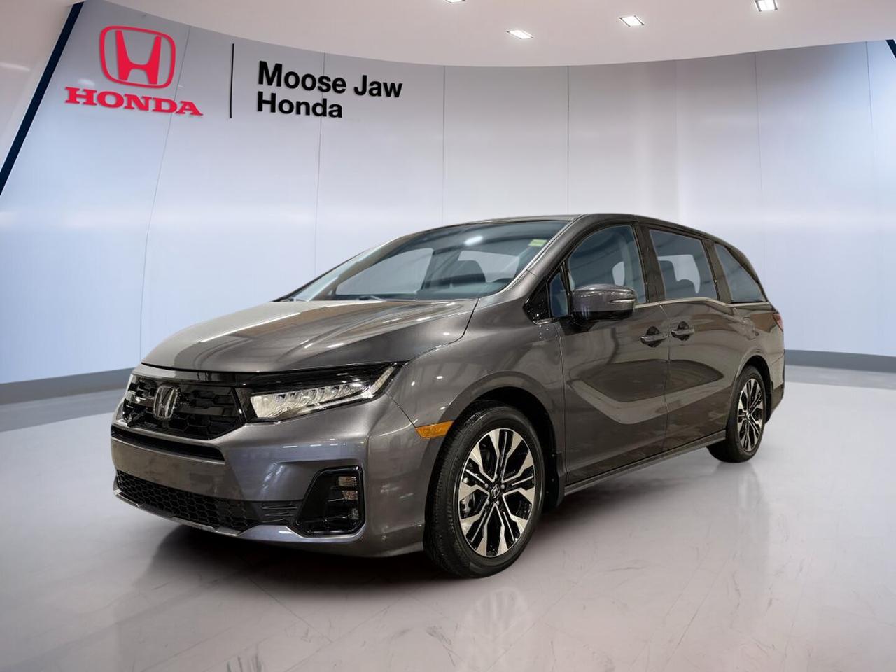 The 2026 Honda Odyssey Touring is a brand-new minivan built for busy family life in Moose Jaw. It pairs proven Honda engineering with a smooth 10-Speed Automatic transmission and a strong 3.5L 24-valve direct-injection SOHC i-VTEC V6 engine. Finished in Grey with a Black interior, this Odyssey Touring delivers space, confidence, and everyday ease.

This front-wheel-drive 2026 Honda Odyssey Touring is designed to make daily driving simple. Its V6 power helps with highway merging and passing, while the automatic transmission supports refined, responsive performance. The cabin layout is made for comfort and flexibility, giving families a practical vehicle that is easy to live with every day.

FEATURES OF THE Odyssey Touring
»» Grey exterior with clean modern presence
»» Black interior with family-friendly layout
»» 10-speed automatic with shift function
»» 3.5L i-VTEC V6 powertrain performance

ADVANCED SAFETY FEATURES
»» Honda safety engineering supports occupant protection
»» Stable front-wheel-drive handling in varied conditions
»» Strong braking feel for confident control
»» Wide minivan design aids road awareness

PERFORMANCE AND EFFICIENCY
»» 3.5L direct-injection V6 delivers smooth power
»» 10-speed automatic helps efficient cruising
»» Front-wheel drive supports balanced daily handling
»» Refined powertrain suits city and highway

COMFORT AND CONVENIENCE
»» Spacious cabin designed for family travel
»» Easy entry helps daily passenger access
»» Flexible seating supports changing cargo needs
»» Quiet ride enhances long-trip comfort

TECHNONOLGY AND CONNECTIVITY
»» Driver-focused controls are clear and simple
»» Modern cabin layout keeps functions organized
»» Automatic transmission includes shift functionality
»» Useful displays support everyday driving information

CARGO SPACE
»» Large rear area suits family gear
»» Minivan design supports versatile load space
»» Cabin layout allows practical storage solutions
»» Ideal for errands trips and travel

AWARDS & RECOGNITIONS
»» Top Safety Pick, Insurance Institute for Highway Safety, 2024
»» Best Minivan, U.S. News and World Report, 2025

WHAT OTHER OWNERS LIKE
»» Smooth V6 power for easy driving
»» Spacious cabin for passengers and gear
»» Comfortable ride on longer family trips
»» Practical minivan versatility every single day

The 2026 Honda Odyssey Touring is a smart choice for drivers who need room, strength, and day-to-day usability. Its Grey exterior gives it a polished look, while the Black interior keeps the cabin classic and easy to maintain. With brand-new condition and trusted Honda design, it is ready for school runs, road trips, and everything in between.

At Moose Jaw Honda in Moose Jaw, this new 2026 Honda Odyssey Touring offers the kind of capability families want most. You get strong V6 performance, a smooth-shifting automatic transmission, and the flexible space that makes a minivan such a valuable part of daily life. It is practical, refined, and ready to serve for years ahead.

This 2026 Honda Odyssey Tourings VIN is: 5FNRL6H83TB502163.<p>The 2026 Honda Odyssey Touring is a brand-new minivan built for busy family life in Moose Jaw. It pairs proven Honda engineering with a smooth 10-Speed Automatic transmission and a strong 3.5L 24-valve direct-injection SOHC i-VTEC V6 engine. Finished in Grey with a Black interior</p>
<p> and everyday ease.

This front-wheel-drive 2026 Honda Odyssey Touring is designed to make daily driving simple. Its V6 power helps with highway merging and passing</p>
<p> giving families a practical vehicle that is easy to live with every day.

FEATURES OF THE Odyssey Touring
»» Grey exterior with clean modern presence
»» Black interior with family-friendly layout
»» 10-speed automatic with shift function
»» 3.5L i-VTEC V6 powertrain performance

ADVANCED SAFETY FEATURES
»» Honda safety engineering supports occupant protection
»» Stable front-wheel-drive handling in varied conditions
»» Strong braking feel for confident control
»» Wide minivan design aids road awareness

PERFORMANCE AND EFFICIENCY
»» 3.5L direct-injection V6 delivers smooth power
»» 10-speed automatic helps efficient cruising
»» Front-wheel drive supports balanced daily handling
»» Refined powertrain suits city and highway

COMFORT AND CONVENIENCE
»» Spacious cabin designed for family travel
»» Easy entry helps daily passenger access
»» Flexible seating supports changing cargo needs
»» Quiet ride enhances long-trip comfort

TECHNONOLGY AND CONNECTIVITY
»» Driver-focused controls are clear and simple
»» Modern cabin layout keeps functions organized
»» Automatic transmission includes shift functionality
»» Useful displays support everyday driving information

CARGO SPACE
»» Large rear area suits family gear
»» Minivan design supports versatile load space
»» Cabin layout allows practical storage solutions
»» Ideal for errands trips and travel

AWARDS & RECOGNITIONS
»» Top Safety Pick</p>
<p> 2025

WHAT OTHER OWNERS LIKE
»» Smooth V6 power for easy driving
»» Spacious cabin for passengers and gear
»» Comfortable ride on longer family trips
»» Practical minivan versatility every single day

The 2026 Honda Odyssey Touring is a smart choice for drivers who need room</p>
<p> while the Black interior keeps the cabin classic and easy to maintain. With brand-new condition and trusted Honda design</p>
<p> this new 2026 Honda Odyssey Touring offers the kind of capability families want most. You get strong V6 performance</p>