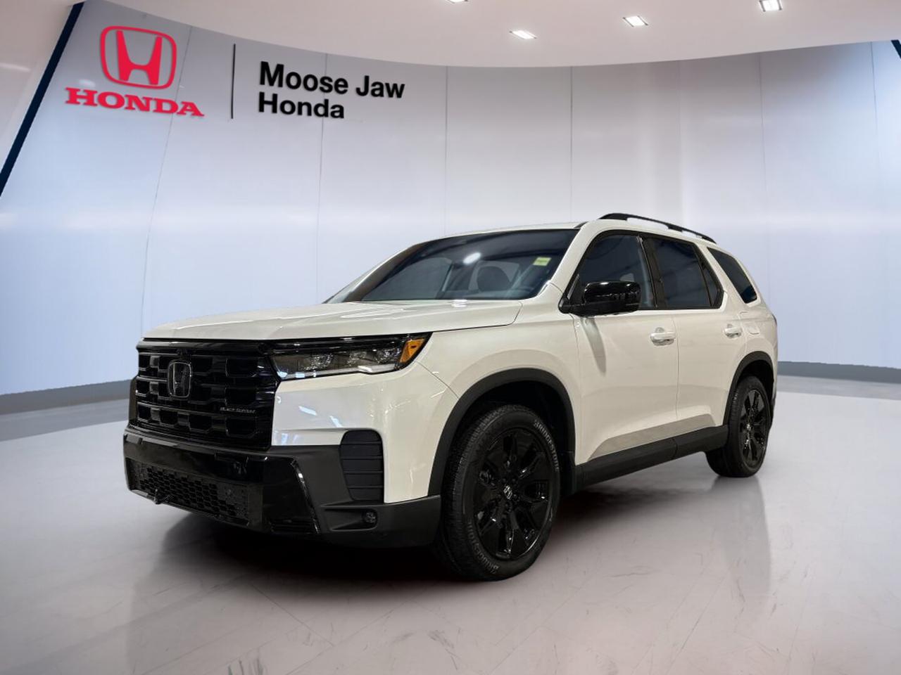 The 2026 Honda Pilot Black Edition is a brand-new SUV built for busy family life in Moose Jaw. It pairs bold White paint with a Black interior for a clean, upscale look. With a 3.5-litre V6, 10-speed automatic transmission, and all-wheel drive, this Honda delivers strong confidence in every season.

This 2026 Honda Pilot Black Edition is designed to handle daily drives, weekend trips, and long highway runs with ease. Its V6 power feels smooth and capable, while the automatic transmission helps deliver refined response. The all-wheel-drive system adds sure-footed traction when roads turn wet, snowy, or rough.

FEATURES OF THE Pilot Black Edition

»» White exterior with premium black interior
»» 3.5-litre V6 with Dual VTC
»» 10-speed automatic with shift capability
»» All-wheel drive for year-round confidence

ADVANCED SAFETY FEATURES

»» Honda Sensing suite supports safer driving
»» Driver-assist systems help reduce driving stress
»» Strong body structure enhances occupant protection
»» All-wheel drive aids slippery-road stability

PERFORMANCE AND EFFICIENCY

»» 3.5-litre V6 delivers smooth strong power
»» 10-speed automatic supports refined acceleration
»» Dual VTC helps optimize engine response
»» All-wheel drive improves all-season traction

COMFORT AND CONVENIENCE

»» Spacious cabin suits families and gear
»» Four-door SUV layout adds easy access
»» Black interior creates a premium feel
»» Smooth transmission helps relaxed daily driving

TECHNONOLGY AND CONNECTIVITY

»» Clear driver information supports easy operation
»» Modern controls keep functions within reach
»» Shift-enabled automatic adds driver engagement
»» Cabin design supports intuitive daily use

CARGO SPACE

»» Large rear area fits family cargo
»» SUV shape supports flexible loading needs
»» Wide cabin helps carry passengers comfortably
»» Ideal for errands trips and luggage

AWARDS & RECOGNITIONS

»» Top Safety Pick, Insurance Institute for Highway Safety, 2025
»» Best Buy Award, The Car Guide, 2025

WHAT OTHER OWNERS LIKE

»» Strong V6 power for confident passing
»» Smooth ride quality on long trips
»» Spacious interior for family flexibility
»» All-wheel drive confidence in winter

At Moose Jaw Honda, this new 2026 Honda Pilot Black Edition stands out as a smart choice for drivers who want space, power, and year-round usability. It offers the proven strength of a V6 engine and the control of all-wheel drive, making it well suited to Saskatchewan roads and changing weather.

This 2026 Honda Pilot Black Edition also brings the confidence buyers expect from a modern Honda SUV. Its balanced performance, roomy design, and premium appearance make it easy to enjoy every day. For families and active drivers in Moose Jaw, this new SUV is ready to do more.

This 2026 Honda Pilot Black Editions VIN is: 5FNYG1H90TB501919.<p>The 2026 Honda Pilot Black Edition is a brand-new SUV built for busy family life in Moose Jaw. It pairs bold White paint with a Black interior for a clean</p>
<p> this Honda delivers strong confidence in every season.

This 2026 Honda Pilot Black Edition is designed to handle daily drives</p>
<p> while the automatic transmission helps deliver refined response. The all-wheel-drive system adds sure-footed traction when roads turn wet</p>
<p> or rough.

FEATURES OF THE Pilot Black Edition

»» White exterior with premium black interior
»» 3.5-litre V6 with Dual VTC
»» 10-speed automatic with shift capability
»» All-wheel drive for year-round confidence

ADVANCED SAFETY FEATURES

»» Honda Sensing suite supports safer driving
»» Driver-assist systems help reduce driving stress
»» Strong body structure enhances occupant protection
»» All-wheel drive aids slippery-road stability

PERFORMANCE AND EFFICIENCY

»» 3.5-litre V6 delivers smooth strong power
»» 10-speed automatic supports refined acceleration
»» Dual VTC helps optimize engine response
»» All-wheel drive improves all-season traction

COMFORT AND CONVENIENCE

»» Spacious cabin suits families and gear
»» Four-door SUV layout adds easy access
»» Black interior creates a premium feel
»» Smooth transmission helps relaxed daily driving

TECHNONOLGY AND CONNECTIVITY

»» Clear driver information supports easy operation
»» Modern controls keep functions within reach
»» Shift-enabled automatic adds driver engagement
»» Cabin design supports intuitive daily use

CARGO SPACE

»» Large rear area fits family cargo
»» SUV shape supports flexible loading needs
»» Wide cabin helps carry passengers comfortably
»» Ideal for errands trips and luggage

AWARDS & RECOGNITIONS

»» Top Safety Pick</p>
<p> 2025

WHAT OTHER OWNERS LIKE

»» Strong V6 power for confident passing
»» Smooth ride quality on long trips
»» Spacious interior for family flexibility
»» All-wheel drive confidence in winter

At Moose Jaw Honda</p>
<p> and year-round usability. It offers the proven strength of a V6 engine and the control of all-wheel drive</p>
<p> making it well suited to Saskatchewan roads and changing weather.

This 2026 Honda Pilot Black Edition also brings the confidence buyers expect from a modern Honda SUV. Its balanced performance</p>
<p> and premium appearance make it easy to enjoy every day. For families and active drivers in Moose Jaw</p>