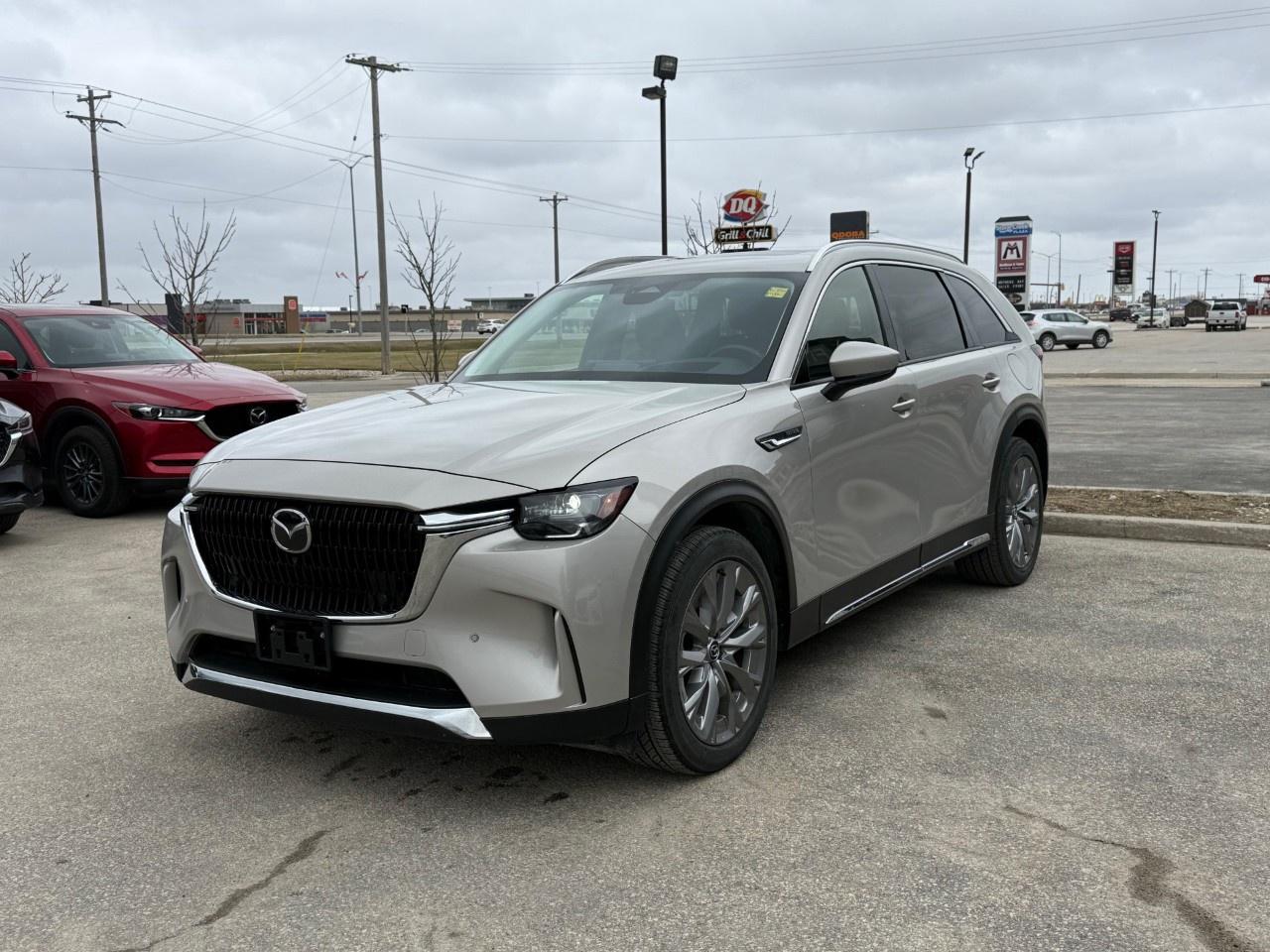 This 2025 Mazda CX-90 GT MHEV delivers a premium, smooth driving experience powered by a 280-hp 3.3L turbocharged inline-six engine paired with a 48-volt mild-hybrid assist system and standard i-Activ AWD. The upscale, three-row cabin elevates everyday utility with black leather upholstery, a power-sliding panoramic moonroof, a 12-speaker Bose premium sound system, and an expansive 12.3-inch full-colour touchscreen. Come by Highway Mazda today!