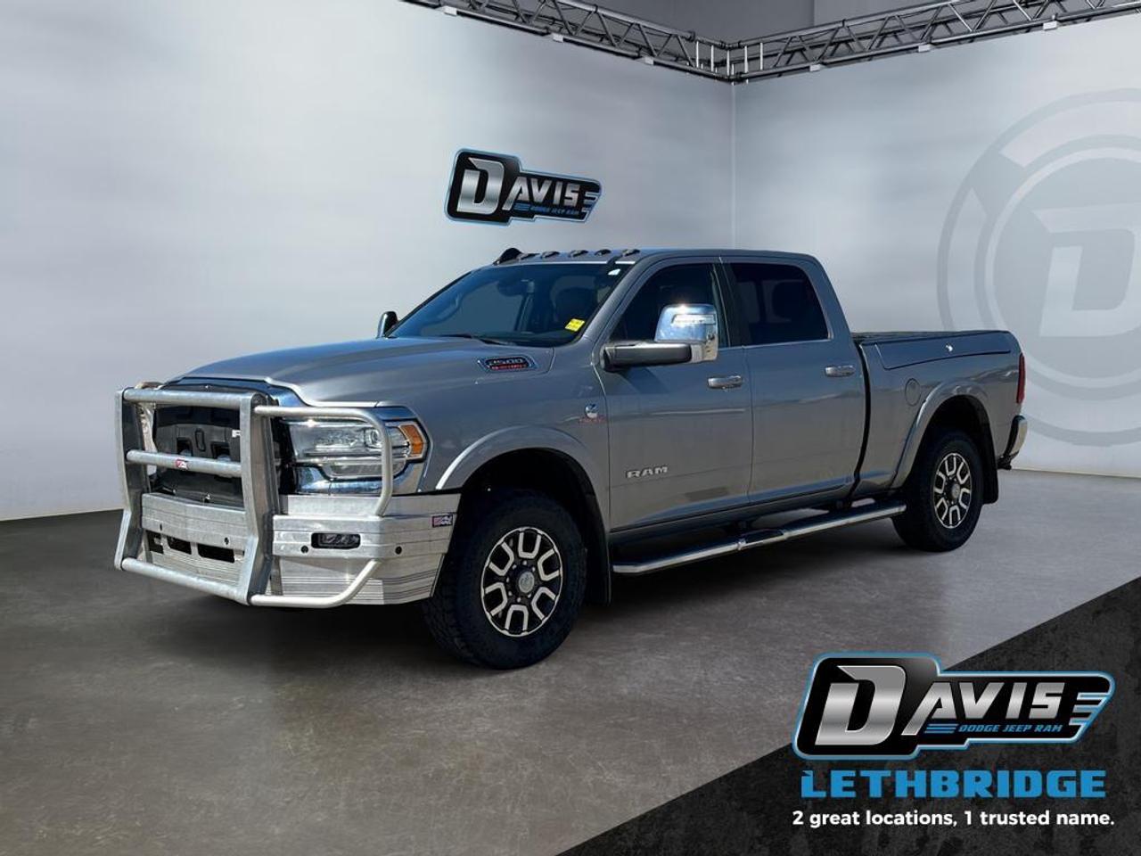 This ultra capable Heavy Duty Ram 2500 is a muscular workhorse ready for any job you put in front of it. This 2023 Ram 2500 is fresh on our lot in Lethbridge. <br /> <br />Endlessly capable, this 2023 Ram 2500HD pulls out all the stops, and has the towing capacity that sets it apart from the competition. On top of its proven Ram toughness, this Ram 2500HD has an ultra-quiet cabin full of amazing tech features that help make your workday more enjoyable. Whether you're in the commercial sector or looking for serious recreational towing rig, this impressive 2500HD is ready for anything that you are. This sought after diesel Crew Cab 4X4 pickup has 95,293 km. Stock number 41448 is Silver in colour. It has an Automatic transmission and is powered by a Cummins 370HP 6.7L Straight 6 Cylinder Engine.<br /> <br />To apply right now for financing use this link: <a href=https://lethbridge.davisdodge.ca/free-credit-check/ target=_blank rel=nofollow noopener noreferrer>https://lethbridge.davisdodge.ca/free-credit-check/</a><br /><br /> <br /><br />Locally Owned & Trusted for Over 35 Years  Davis Dodge in Lethbridge, AB <br /><br /> At Davis Dodge, weve proudly served the Lethbridge community for more than 35 years, offering an unparalleled car buying experience. Dont just take our word for itour Google reviews speak volumes about our commitment to exceptional service. <br /><br /> Delivery & At-Home Test Drives: Convenient options to suit your lifestyle. <br /><br /> Flexible Financing for Everyone: Get the vehicle you need with financing solutions tailored to your situation. <br /><br /> Full Mechanical Inspections & Professional Cleaning: Every vehicle is thoroughly inspected and cleaned before it hits our lot.<br /><br /> We take all makes and models on trade and offer competitive pricing with inventory that changes daily. Whether you're shopping for a Chrysler, Dodge, Jeep, RAM, or FIAT, our AMVIC Licensed dealership makes it easy to browse, buy, and drive away.<br /><br /> Located in Lethbridge, AB, we proudly serve customers in Fort Macleod, Taber, Claresholm, and Coaldale. Shop online or visit us today to experience the best in sales, service, and selection. Standard bank rates apply; taxes are additional.<br /><br /> Vehicle pricing offer shown expires 2026-04-30. <br /> Come by and check out our fleet of 70+ used cars and trucks and 110+ new cars and trucks for sale in Lethbridge. o~o