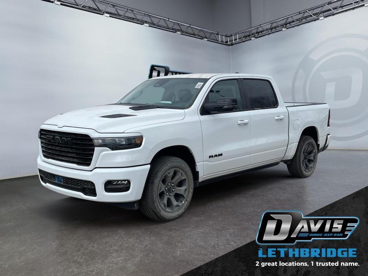 <b>Navigation, Apple CarPlay, Android Auto, 360 Camera, Heated Seats!</b><br /> <br /> <br /> <br />The 2026 Ram 1500 delivers exceptional performance, refined comfort, and cutting-edge innovation for every road ahead. <br /> <br />The Ram 1500's unmatched luxury transcends traditional pickups without compromising its capability. Loaded with best-in-class features, it's easy to see why the Ram 1500 is so popular. With the most towing and hauling capability in a Ram 1500, as well as improved efficiency and exceptional capability, this truck has the grit to take on any task.<br /> <br />This Bright White Crew Cab 4X4 pickup has an Automatic transmission and is powered by a 420HP 3.0L Straight 6 Cylinder Engine. <br /> <br /> Our 1500's trim level is Sport. This Ram 1500 in Sport trim rewards you with front heated seats, a leather-wrapped heated steering wheel, a 360 camera system, a 10-speaker Alpine audio, and a 12-inch infotainment screen with inbuilt navigation, Apple CarPlay and Android Auto, and 4G LTE Wi-Fi hotspot. Additional features include class IV towing equipment, aluminum wheels, power adjustable pedals, intersection collision assist, evasion assist, lane keep assist with lane departure warning, and even more! This vehicle has been upgraded with the following features: Navigation, Apple CarPlay, Android Auto, 360 Camera, Heated Seats, Heated Steering Wheel, Aluminum Wheels.<br /><br /> <br />To apply right now for financing use this link: <a href=https://lethbridge.davisdodge.ca/free-credit-check/ target=_blank rel=nofollow noopener noreferrer>https://lethbridge.davisdodge.ca/free-credit-check/</a><br /><br /> <br /><br />As a premier Chrysler, Dodge, Jeep and RAM dealership, Davis Dodge proudly offers an extensive selection of new and used vehicles to meet every drivers needs. Customers across Lethbridge, Fort Macleod, Taber, Claresholm, Coaldale, and beyond trust us for daily vehicle specials, certified service and parts, and a seamless online inventory experience. <br /><br /> With competitive financing options and expert support, we make car buying easy and enjoyable. <br /><br /> Ready to hit the road? Schedule your test drive today at Davis Dodge, your trusted Chrysler, Dodge, Jeep and RAM dealer in Lethbridge, Alberta.<br /><br /> Vehicle pricing offer shown expires 2026-04-30. <br /> Come by and check out our fleet of 70+ used cars and trucks and 110+ new cars and trucks for sale in Lethbridge. o~o