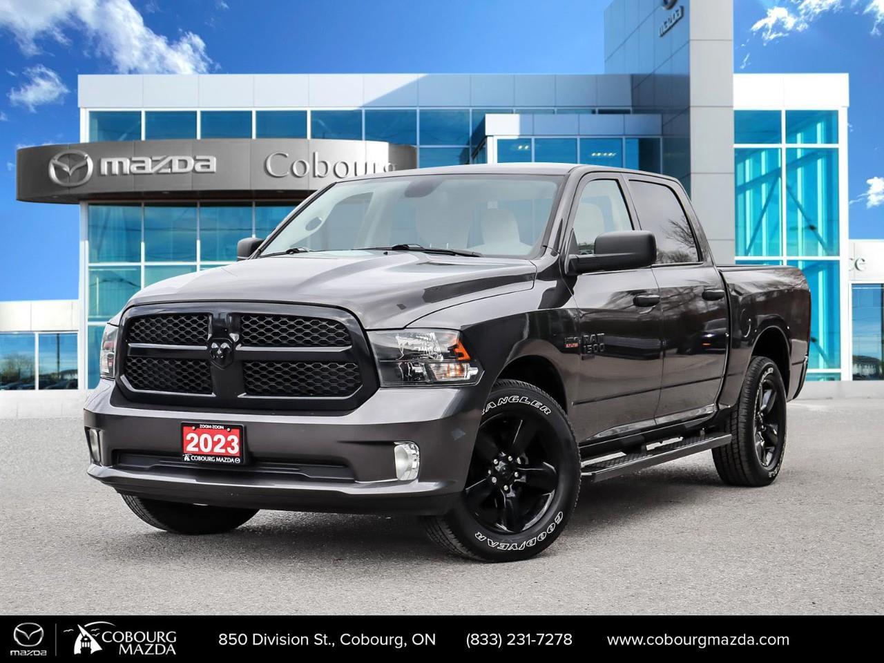 <p>The 2023 Ram 1500 Classic Express in Gray with its robust 4x4 drivetrain offers a confident driving experience for those who value reliability and power. This truck's formidable presence is complemented by a cohesive style that blends functional design with aesthetic appeal. The Gray exterior not only exudes a rugged charm but is also designed to withstand the elements, making it a perfect choice for the Canadian landscape.</p><p>Inside, the gray-toned interior provides a harmonious and inviting atmosphere while still being practical for everyday use. The truck is equipped with essential features like air conditioning, power windows, and cruise control, ensuring comfort and convenience on every journey. Alloy wheels and heated mirrors are part of its sophisticated styling, adding a touch of elegance to this reliable workhorse.</p><p>In terms of technology, the Ram 1500 Classic Express boasts a user-friendly backup camera and Bluetooth connection, offering connectivity and simplicity for modern demands. Safety is bolstered with the inclusion of advanced brake assist, making every drive more secure. Whether towing, commuting, or adventuring, this truck is built to handle it all.</p><p>This vehicle is perfectly tailored for those seeking a dependable, stylish, and capable truck. It caters to outdoor enthusiasts, tradespeople, and families alike. We invite you to contact our dealership to explore the 2023 Ram 1500 Classic Express further and experience its qualities firsthand.</p>