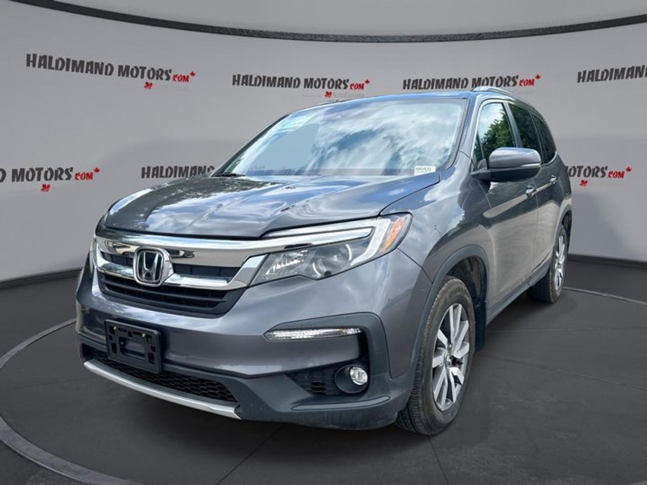 // ACCIDENT FREE!! //<br /><br />This 2019 Honda Pilot Touring 8-Passenger AWD | Leather Seats | Heated Steering is a roomy, family-ready SUV built for busy days in Cayuga and beyond. It pairs a strong 3.5-litre gas engine with automatic transmission and all-wheel drive confidence. Finished in Grey with a Grey interior, this used Honda Pilot shows 82,387 km and delivers comfort, versatility, and smart everyday value.<br /><br />With four doors, seating for up to eight, and a long list of sought-after features, this SUV is ready for school runs, weekend travel, and long highway drives. Highlights include a sunroof, navigation system, heated steering wheel, heated front and rear seats, , trailer hitch, power liftgate, Apple CarPlay, Android Auto, and a backup camera.<br /><br />FEATURES OF THE Pilot Touring 8-Passenger AWD | Leather Seats | Heated Steering<br /><br />   All-wheel drive adds year-round road confidence<br />   Heated steering wheel for cold mornings<br />   Power liftgate helps with busy loading<br /><br />ADVANCED SAFETY FEATURES<br /><br />   Backup camera helps with reversing visibility<br />   Blind spot monitor supports safer lane changes<br />   Lane departure warning adds driving awareness<br />   Side and head airbags enhance protection<br /><br />PERFORMANCE AND EFFICIENCY<br /><br />   3.5-litre gas engine delivers smooth power<br />   Automatic transmission supports easy daily driving<br />   All-wheel drive improves traction in weather<br />   Limited slip differential aids road stability<br /><br />COMFORT AND CONVENIENCE<br /><br />   Heated front seats add winter comfort<br />   Heated rear seats warm second-row passengers<br />   Dual-zone climate control helps everyone relax<br />   Remote starter adds everyday convenience<br /><br />The cabin of this Honda Pilot Touring 8-Passenger AWD | Leather Seats | Heated Steering is built for active families who need flexibility without giving up comfort. Memory settings, power front seats, driver lumbar support, rear climate control, and automatic climate control all help make each trip easier, whether you are commuting or heading out for a weekend away.<br /><br />A heated steering wheel is a welcome touch on cold Ontario mornings, while tinted windows, ambient lighting, and an auto-dimming rearview mirror add a refined feel to the drive. Heated mirrors, retractable mirrors, power windows, and push button start bring added ease to daily use.<br /><br />TECHNONOLGY AND CONNECTIVITY<br /><br />   Navigation system helps guide every trip<br />   Apple CarPlay connects favourite phone apps<br />   Android Auto keeps smartphone features accessible<br />   Bluetooth integration supports hands-free communication<br /><br />This Honda Pilot Touring 8-Passenger AWD | Leather Seats | Heated Steering also supports entertainment and convenience with satellite radio, HD Radio, steering wheel audio controls, and a WiFi hotspot. helping keep passengers happy on longer drives around Ontario and beyond.<br /><br />CARGO SPACE<br /><br />   Power liftgate simplifies cargo area access<br />   Rear trunk access makes loading easier<br />   Eight-passenger layout supports family flexibility<br />   Trailer hitch adds useful hauling capability<br /><br />The cargo area in this Honda Pilot Touring 8-Passenger AWD | Leather Seats | Heated Steering is designed to adapt to changing needs. From groceries and sports gear to luggage and travel supplies, it offers the practical space expected from a well-rounded midsize SUV. The rear spoiler and performance tires also give it a confident, capable look.<br /><br />AWARDS & RECOGNITIONS<br /><br />   Top Safety Pick, Insurance Institute for Highway Safety, 2019<br />   Best Buy Award, The Car Guide, 2019<br /><br />WHAT OTHER OWNERS LIKE<br /><br />   Smooth V6 power for highway driving<br />   Spacious cabin for family road trips<br />   User-friendly infotainment and navigation features<br />   Comfortable ride with strong winter confidence<br /><br />This 2019 Honda Pilot Touring 8-Passenger AWD | Leather Seats | Heated Steering stands out as a practical and well-equipped SUV for drivers who want passenger space, strong feature content, and trusted Honda engineering. Available now at Haldimand Motors Ltd. in Cayuga, it is a smart choice for families who need comfort, capability, and everyday ease in one versatile package.<br /><br />This 2019 Honda Pilot Touring 8-Passenger AWD | Leather Seats | Heated Steerings VIN is: 5FNYF6H75KB506949.<br /><br />WHY CHOOSE US? <br /><br />Honest & Transparent Buying Experience: Weve been a trusted name in business since 1984.<br /><br />STRAIGHTFORWARD PRICING:<br />Our Advertised Price Includes:<br />>>Safety Certification (No separate fee!)<br />>>30-Day 100% Mechanical Warranty<br />>>FREE Carfax History Report.<br />>>No upcharge for paying cash.<br />(Prices Exclude HST and Licensing Fees only.)<br /><br />>>Browse 300+ vehicles all in ONE LOCATION<br /><br />EASY FINANCING: Great rates & open loans<br /><br />WE BUY CARS: Get Top Dollar for your trade-in, or sell us your vehicle for CASH! Even if you dont buy from us!<br /><br />STOP BY TODAY<br />Treat yourself - stop by Haldimand Motors Ltd. located at 42 Talbot St E, Cayuga, ON N0A 1E0 to make this car yours today!<br /><br />https://www.haldimandmotors.com/used/stock-460431.html