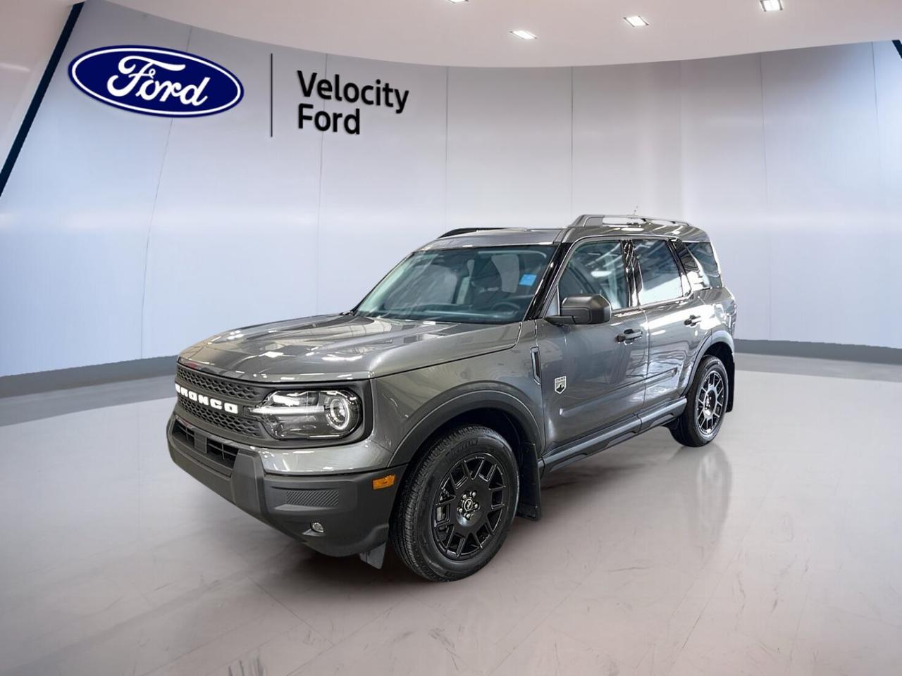 Built for life in Saskatchewan and ready for every season, this brand new 2026 Ford Bronco Sport Big Bend 4x4 at Velocity Ford in Moose Jaw delivers smart utility, confident traction, and everyday comfort. Its Grey exterior pairs well with a MEDIUM LT SMOKED TRUFFLE interior, while the 1.5-litre unleaded engine and 8-speed automatic transmission help make each drive smooth and easy.

The 2026 Ford Bronco Sport Big Bend 4x4 gives you four doors, practical cabin access, and the added confidence of four-wheel drive. Heated front bucket seats, automatic climate control, and a backup camera support daily use with ease. This new SUV is well equipped for commuting, weekend travel, and changing road conditions across Canada.

FEATURES OF THE Bronco Sport Big Bend 4x4

»» Brand new SUV with four-wheel drive
»» 1.5-litre unleaded engine with automatic
»» Grey exterior with warm-toned interior
»» Heated front bucket seats included

ADVANCED SAFETY FEATURES

»» Anti-lock braking system supports controlled stops
»» Stability control helps maintain road confidence
»» Blind spot monitor aids lane awareness
»» Lane departure warning adds extra support

PERFORMANCE AND EFFICIENCY

»» 1.5-litre engine balances power and efficiency
»» Eight-speed automatic supports smooth shifting
»» Four-wheel drive adds year-round traction
»» Power steering helps easy urban handling

COMFORT AND CONVENIENCE

»» Heated front seats add winter comfort
»» Automatic climate control keeps cabin pleasant
»» Cruise control supports relaxed highway travel
»» Power windows add everyday convenience

TECHNONOLGY AND CONNECTIVITY

»» Bluetooth integration supports hands-free calling
»» WiFi hotspot helps keep devices connected
»» Satellite radio expands entertainment choices
»» Steering wheel audio controls simplify use

CARGO SPACE

»» Rear trunk access makes loading easier
»» Four-door layout supports daily practicality
»» Flexible cabin suits errands and travel
»» Useful cargo room for active lifestyles

WHAT OTHER OWNERS LIKE

»» Easy driving size for city streets
»» Confident all-weather traction from four-wheel drive
»» Comfortable heated seats for cold mornings
»» Helpful driver aids for daily peace

This 2026 Ford Bronco Sport Big Bend 4x4 is designed for drivers who want useful features without extra fuss. LED headlamps help improve visibility, while automatic headlights add convenience when light changes fast. Heated mirrors, electric mirrors, tinted windows, and a rear window defroster all help this SUV stay ready for real Canadian weather.

Inside, the 2026 Ford Bronco Sport Big Bend 4x4 keeps things simple and functional. The adjustable steering wheel helps you find a comfortable driving position, and the drivers seat lumbar support adds comfort on longer trips. A drivers side power seat, illuminated vanity mirrors, push button start, and ambient lighting package all add thoughtful touches.

Safety and peace of mind remain a strong part of this new Ford SUV. Driver and passenger airbags, side impact airbags, head side airbags, child safety locks, tire pressure monitoring, automatic door locks, and a passenger airbag sensor all help support secure family travel. The backup camera also helps when reversing in tight spaces.

This 2026 Ford Bronco Sport Big Bend 4x4s VIN is: 3FMCR9BNXTRE37293.