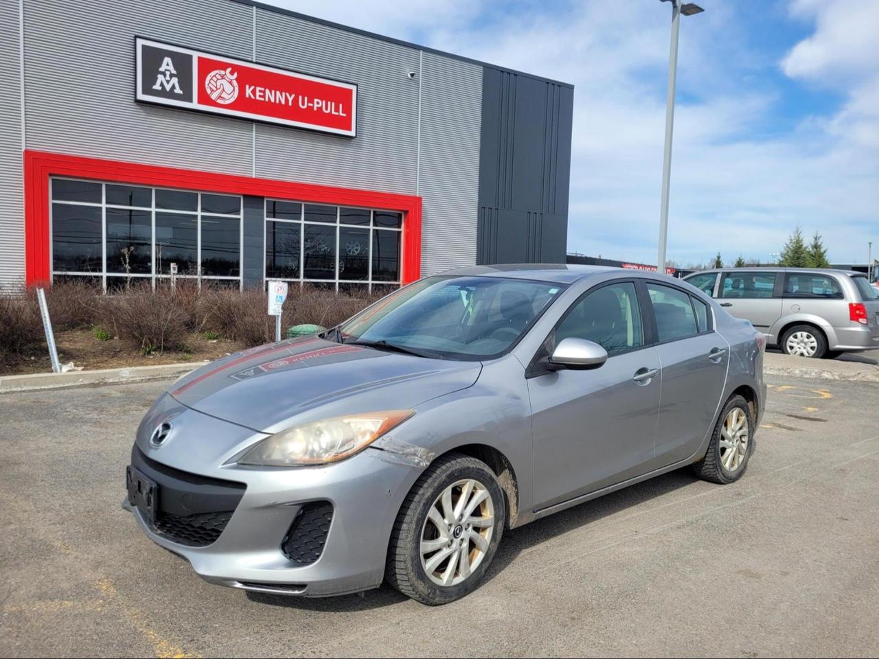 2013 Mazda 3 in Liquid Silver metallic. The vehicle has 172,293km. The vehicle runs and drives ok. Rust spots found around the vehicle mainly on the rockers. Check engine light is on. Vibrations felt inside the cabin. Front bumper has cracks/damages. We dont perform any mechanical/safety inspections. The vehicle is sold as is and might need some work.