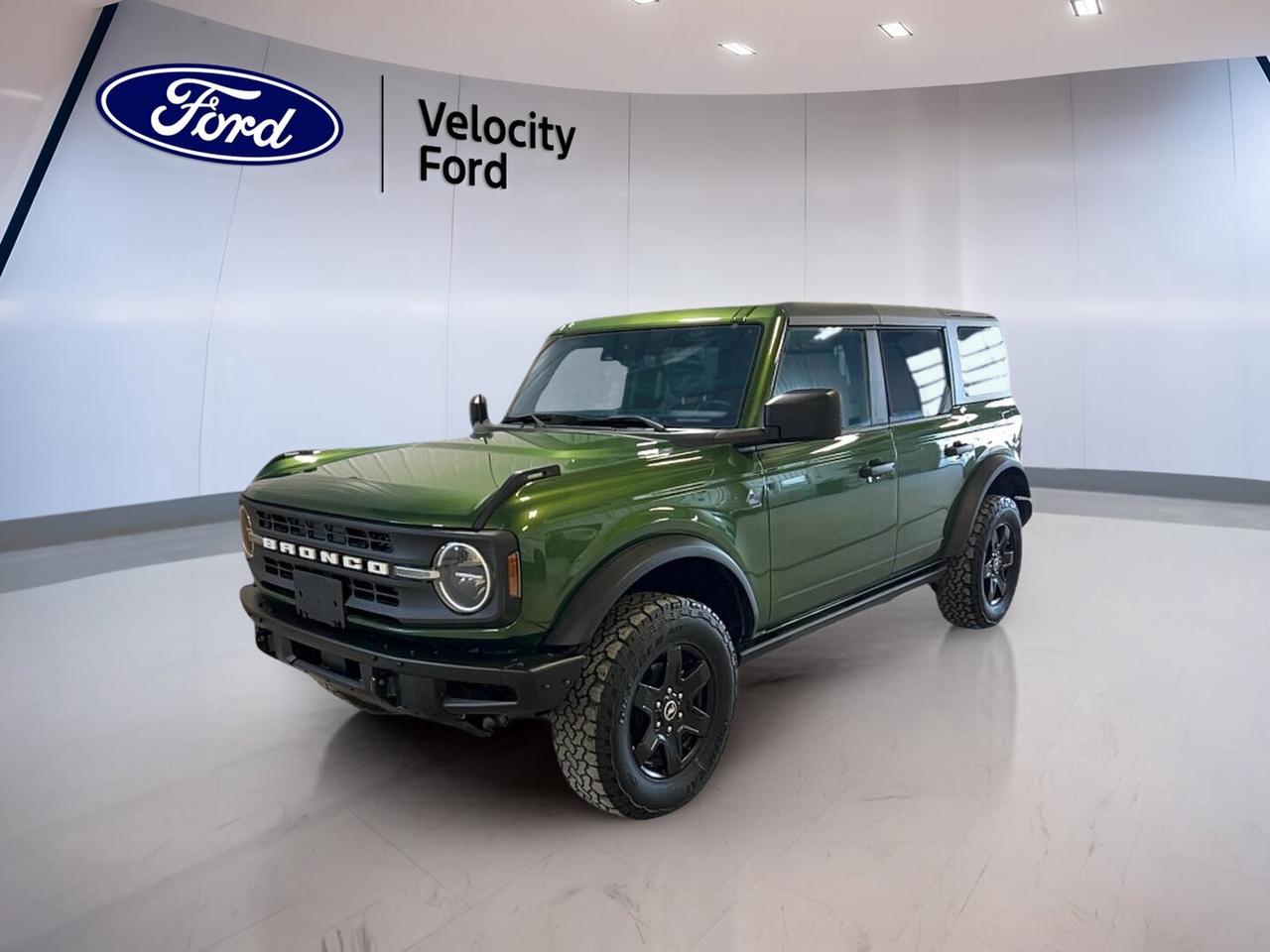 Built for real adventure and ready for daily life, this used 2022 Ford Bronco Black Diamond 4 Door 4x4 at Velocity Ford in Moose Jaw delivers rugged capability with smart everyday comfort. It wears a Green exterior with a Black interior, has 91,232 km, and uses a 2.7-litre unleaded engine with automatic transmission.

The 2022 Ford Bronco Black Diamond 4 Door 4x4 is known for its durable off-road focus and open-air design. Four doors make access easy for family or friends, while four-wheel drive, off-road tires, steel wheels, and a rear tow hook help this SUV handle rough roads, trails, and changing Prairie weather with confidence.

FEATURES OF THE Bronco Black Diamond 4 Door 4x4

»» Convertible design adds open-air driving fun
»» Four-wheel drive supports serious trail capability
»» Off-road tires improve loose-surface traction
»» Steel wheels add durable everyday toughness

ADVANCED SAFETY FEATURES

»» Backup camera helps with reversing visibility
»» Anti-lock brakes support controlled stopping
»» Stability control helps maintain vehicle balance
»» Side and head airbags add protection

PERFORMANCE AND EFFICIENCY

»» 2.7-litre unleaded engine delivers strong power
»» Automatic transmission supports smooth daily driving
»» Limited slip differential aids off-road traction
»» Four-wheel drive boosts grip in weather

COMFORT AND CONVENIENCE

»» Cruise control supports relaxed highway travel
»» Front air conditioning keeps cabin comfortable
»» Power windows add everyday ease
»» Heated mirrors help in cold mornings

TECHNONOLGY AND CONNECTIVITY

»» Bluetooth integration supports hands-free phone use
»» WiFi hotspot helps keep devices connected
»» Satellite radio expands entertainment choices
»» Steering wheel audio controls simplify access

CARGO SPACE

»» Rear trunk access simplifies cargo loading
»» Four-door layout helps passenger entry
»» Spare tire adds travel reassurance
»» Versatile SUV shape supports gear hauling

AWARDS & RECOGNITIONS

»» North American Utility Vehicle winner, North American Car Awards, 2021
»» Best 4x4 SUV, The Car Guide, 2022

WHAT OTHER OWNERS LIKE

»» Strong off-road ability in varied conditions
»» Removable roof adds extra driving enjoyment
»» Useful technology feels simple and practical
»» Rugged design suits active outdoor lifestyles

This 2022 Ford Bronco Black Diamond 4 Door 4x4 also brings useful details that make daily ownership easier. Power steering helps with low-speed manoeuvres and parking. Electric mirrors and automatic headlights add convenience in changing conditions. Push button start gives quick access, while tinted windows help with comfort and cabin privacy.

Inside, the 2022 Ford Bronco Black Diamond 4 Door 4x4 keeps things practical and focused. The adjustable steering wheel helps drivers find a comfortable position, and illuminated driver and passenger vanity mirrors add a helpful touch. Child safety locks and passenger airbag sensor features support family use when needed.

This SUV is a great fit for drivers who want true utility without giving up convenience. The 2022 Ford Bronco Black Diamond 4 Door 4x4 combines trail-ready hardware, useful cabin technology, and classic open-air freedom in one capable package. If you want a rugged used SUV from Velocity Ford in Moose Jaw, this Bronco deserves a close look.

This 2022 Ford Bronco Black Diamond 4 Door 4x4s VIN is: 1FMEE5BP7NLA85810.