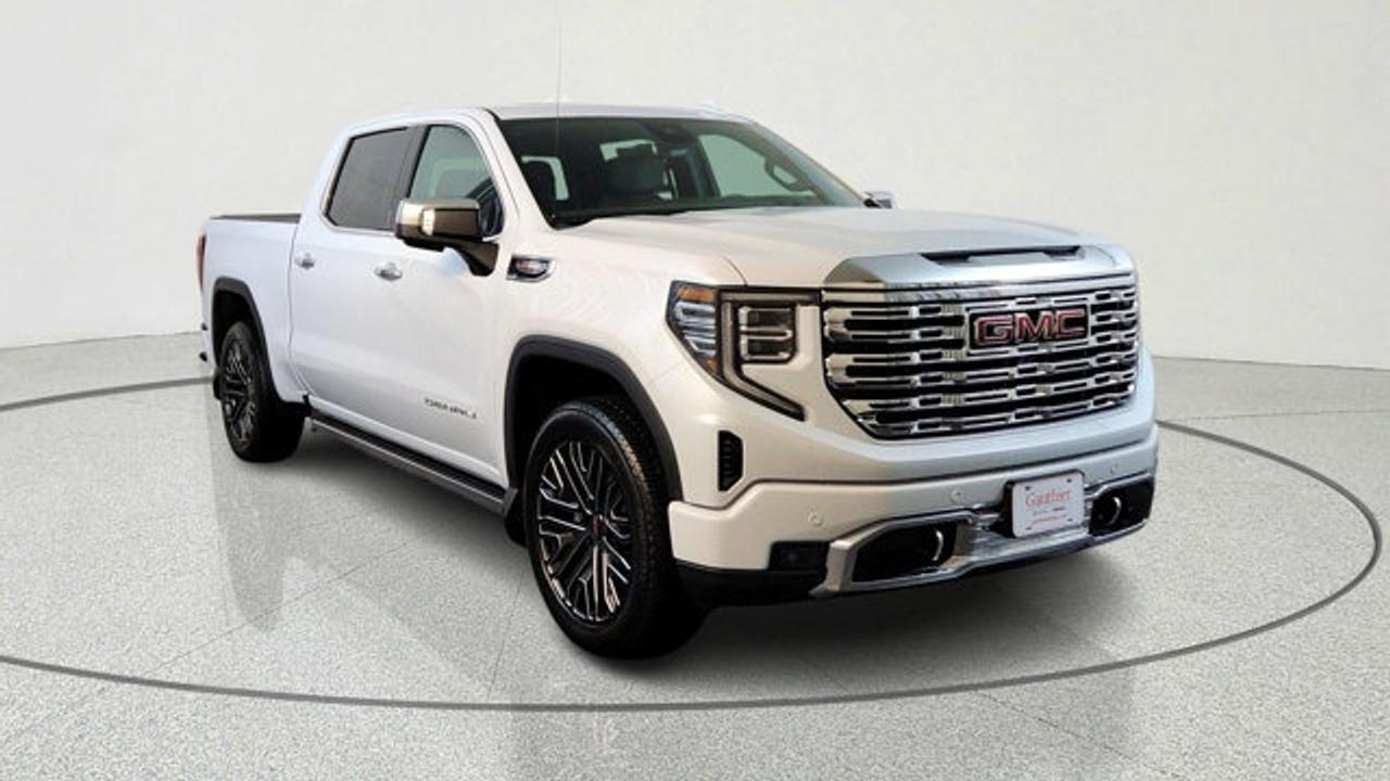 This Sierra 1500 Denali Reserve stands out with its robust 6.2L V8 engine, paired with a smooth 10-speed automatic transmission for effortless acceleration and towing. Four-wheel drive and adaptive ride control handle Manitobas varied terrain, from city streets in Winnipeg to rural trails. Advanced trailering tech like the integrated brake controller and hitch guidance make it ideal for work or play.<br />Inside, enjoy a spacious crew cab with heated and ventilated front bucket seats, plus heated rear seats. The 13.4-inch infotainment screen supports wireless Apple CarPlay and Android Auto, while the Bose premium sound system fills the cabin with rich audio. Practical touches like the MultiPro tailgate and spray-on bedliner add versatility for daily use.<br />Safety shines with forward collision alert, lane keep assist, blind-spot monitoring, and rear cross-traffic braking. The Denali Reserve Super Cruise package brings hands-free driving capability on compatible roads, plus a power sunroof and MultiPro power steps for easy access.