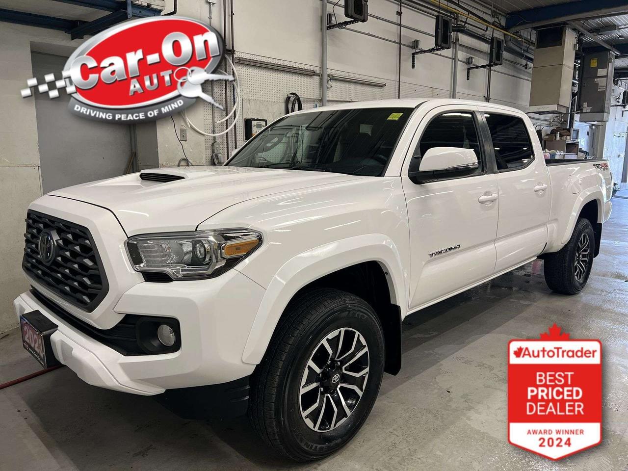 ONLY 32,000KMS!! TRD SPORT 4X4 Double Cab w/ Heated seats, Android Auto/ Apple CarPlay, 17-inch alloys, navigation, adaptive cruise control, pre-collision system, lane departure warning, backup camera, tow package, 6-foot bed w/ bedliner, dual-zone climate control, keyless entry w/ push start, full power group incl. power seat, automatic headlights w/ auto highbeams, garage door opener, auto-dimming rearview mirror, Bluetooth and Sirius XM!*This car was used as a previous daily rental*
