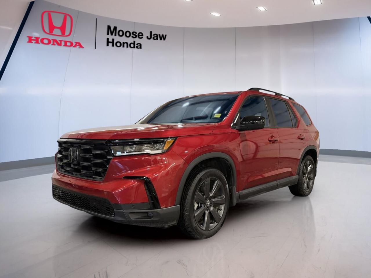 The 2024 Honda Pilot Sport is a smart choice for families who need space, strength, and everyday ease. This used SUV at Moose Jaw Honda has 23,950 km and delivers the confidence of Honda engineering with practical capability for life in Saskatchewan. Its 3.5-litre V6 engine, all-wheel drive, and 10-speed automatic transmission make it ready for city trips, highway travel, and changing road conditions.

FEATURES OF THE Pilot Sport

»» 3.5-litre V6 with idle-stop system
»» 10-speed automatic with smooth shifting
»» All-wheel drive for added traction
»» Spacious SUV design for family use

ADVANCED SAFETY FEATURES

»» Honda Sensing driver-assist safety technologies
»» Collision mitigation braking support included
»» Road departure mitigation system included
»» Advanced airbag protection for occupants

PERFORMANCE AND EFFICIENCY

»» 3.5-litre V6 delivers strong performance
»» 10-speed automatic supports smooth acceleration
»» All-wheel drive improves year-round control
»» Idle-stop system helps save fuel

COMFORT AND CONVENIENCE

»» Spacious cabin for passengers and gear
»» Four-door access for daily convenience
»» Easy driving position with clear visibility
»» Flexible interior suits busy family life

TECHNONOLGY AND CONNECTIVITY

»» Clear infotainment access for daily driving
»» Helpful driver information display included
»» Modern controls are easy to use
»» Cabin layout supports simple operation

CARGO SPACE

»» Large rear cargo area for gear
»» SUV design supports versatile hauling
»» Roomy interior fits family essentials
»» Practical space for travel and errands

AWARDS & RECOGNITIONS

»» Top Safety Pick, Insurance Institute for Highway Safety, 2024

WHAT OTHER OWNERS LIKE

»» Strong V6 power for highway passing
»» Smooth ride quality in daily use
»» Spacious cabin for family comfort
»» Confident all-wheel drive traction year-round

The 2024 Honda Pilot Sport stands out with balanced power and real-world usability. The V6 engine gives this SUV strong passing power and smooth response, while the 10-speed automatic helps keep the drive refined. All-wheel drive adds extra confidence when roads are wet, snowy, or uneven.

Inside, the 2024 Honda Pilot Sport is built for busy days and longer drives. The cabin offers generous room for passengers, and the cargo area is ready for groceries, sports gear, luggage, or weekend supplies. Its practical layout makes daily use simple, whether you are commuting, school-running, or heading out of town.

This SUV is also well suited to drivers who want proven safety and trusted durability. Hondas reputation for long-term value adds peace of mind, and the Pilot continues to be appreciated for its family-friendly design, strong road manners, and dependable performance. With only 23,950 km, this used 2024 Honda Pilot Sport offers plenty of life ahead.

Available now at Moose Jaw Honda in Moose Jaw, this 2024 Honda Pilot Sport brings together capability, comfort, and confidence in one well-rounded SUV. It is a solid fit for drivers who want useful space, V6 power, and all-weather traction without giving up everyday ease.

This 2024 Honda Pilot Sports VIN is: 5FNYG1H36RB501427.<p>950 km and delivers the confidence of Honda engineering with practical capability for life in Saskatchewan. Its 3.5-litre V6 engine</p>
<p> and changing road conditions.

FEATURES OF THE Pilot Sport

»» 3.5-litre V6 with idle-stop system
»» 10-speed automatic with smooth shifting
»» All-wheel drive for added traction
»» Spacious SUV design for family use

ADVANCED SAFETY FEATURES

»» Honda Sensing driver-assist safety technologies
»» Collision mitigation braking support included
»» Road departure mitigation system included
»» Advanced airbag protection for occupants

PERFORMANCE AND EFFICIENCY

»» 3.5-litre V6 delivers strong performance
»» 10-speed automatic supports smooth acceleration
»» All-wheel drive improves year-round control
»» Idle-stop system helps save fuel

COMFORT AND CONVENIENCE

»» Spacious cabin for passengers and gear
»» Four-door access for daily convenience
»» Easy driving position with clear visibility
»» Flexible interior suits busy family life

TECHNONOLGY AND CONNECTIVITY

»» Clear infotainment access for daily driving
»» Helpful driver information display included
»» Modern controls are easy to use
»» Cabin layout supports simple operation

CARGO SPACE

»» Large rear cargo area for gear
»» SUV design supports versatile hauling
»» Roomy interior fits family essentials
»» Practical space for travel and errands

AWARDS & RECOGNITIONS

»» Top Safety Pick</p>
<p> 2024

WHAT OTHER OWNERS LIKE

»» Strong V6 power for highway passing
»» Smooth ride quality in daily use
»» Spacious cabin for family comfort
»» Confident all-wheel drive traction year-round

The 2024 Honda Pilot Sport stands out with balanced power and real-world usability. The V6 engine gives this SUV strong passing power and smooth response</p>
<p> while the 10-speed automatic helps keep the drive refined. All-wheel drive adds extra confidence when roads are wet</p>
<p> the 2024 Honda Pilot Sport is built for busy days and longer drives. The cabin offers generous room for passengers</p>
<p> or heading out of town.

This SUV is also well suited to drivers who want proven safety and trusted durability. Hondas reputation for long-term value adds peace of mind</p>
<p> this used 2024 Honda Pilot Sport offers plenty of life ahead.

Available now at Moose Jaw Honda in Moose Jaw</p>
<p> and all-weather traction without giving up everyday ease.

This 2024 Honda Pilot Sports VIN is: 5FNYG1H36RB501427.</p>