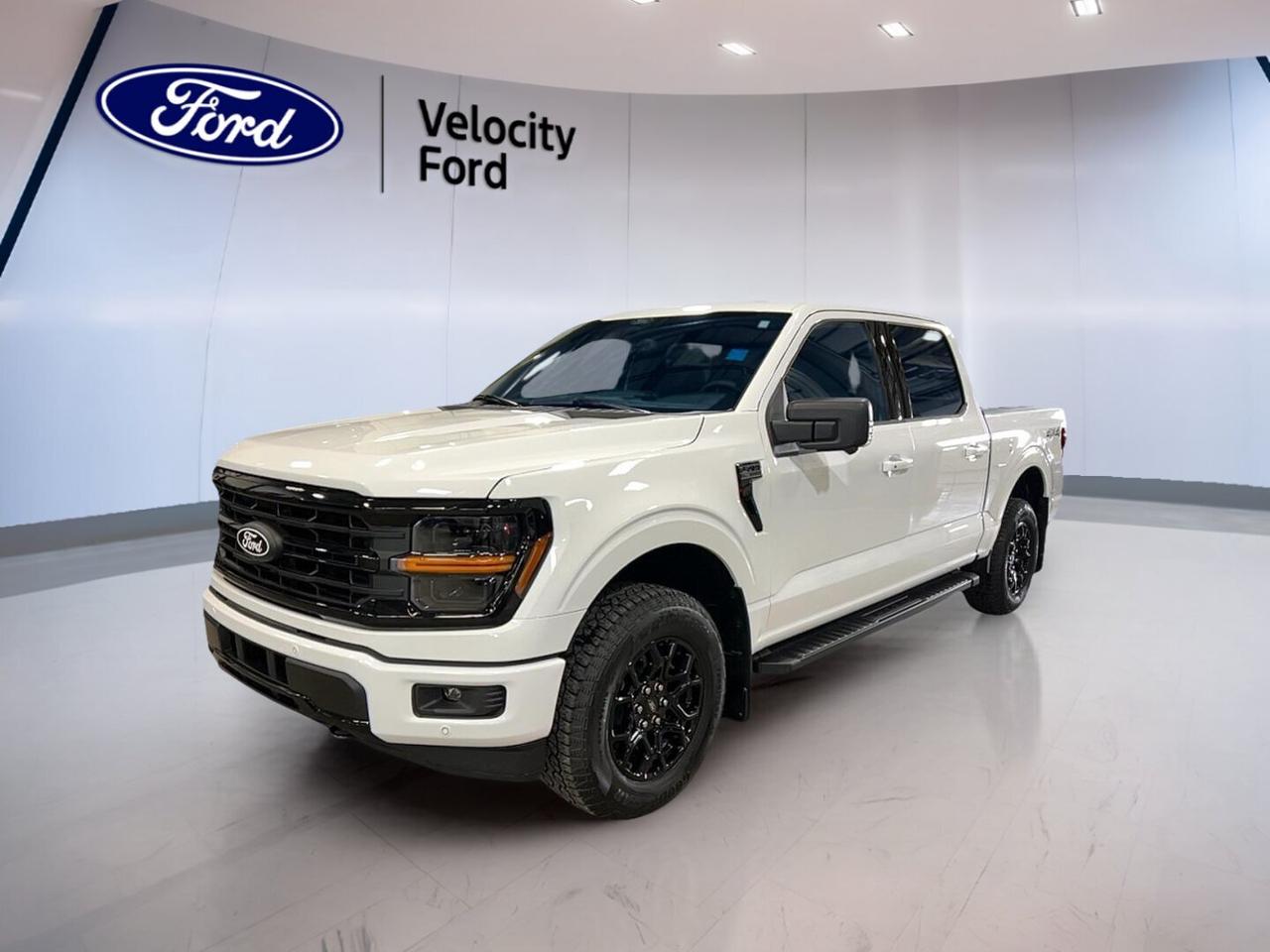 Built for hard work and daily comfort, this brand new 2026 Ford F-150 XLT 4WD SuperCrew 5.5 Box is ready for life in Moose Jaw. Its White exterior, Black interior, four-door layout, automatic transmission, and 3.5-litre unleaded engine give you strong capability with easy everyday use.

At Velocity Ford, this full-size truck delivers the space families want and the toughness job sites demand. Four-wheel drive adds year-round confidence, while its 4,671 kg towing capacity helps you handle trailers, equipment, and weekend gear with the strength expected from a new Ford pickup.

FEATURES OF THE F-150 XLT 4WD SuperCrew 5.5 Box
»» SuperCrew cab adds roomy rear passenger space
»» Four-wheel drive supports traction on rough roads
»» 5.5-foot box balances cargo and manoeuvrability
»» XLT trim adds useful everyday equipment

TRUCK FEATURES
»» Towing capacity rated at 4,671 kg
»» Rear tow hook adds practical pulling support
»» Off-road tires help on uneven terrain
»» Short box aids parking and loading

ADVANCED SAFETY FEATURES
»» Backup camera helps with reversing visibility
»» Lane departure warning supports safer travel
»» Blind spot monitor adds lane-change awareness
»» Side and head airbags enhance protection

PERFORMANCE AND EFFICIENCY
»» 3.5-litre unleaded engine delivers strong output
»» Automatic transmission supports smooth daily driving
»» Dual shift mode adds driver control
»» Four-wheel drive improves traction in all seasons

COMFORT AND CONVENIENCE
»» Cruise control helps on long highway trips
»» Front air conditioning keeps cabin comfortable
»» Power windows add everyday ease of use
»» Driver lumbar support improves seat comfort

TECHNONOLGY AND CONNECTIVITY
»» Bluetooth integration supports hands-free phone use
»» WiFi hotspot helps keep devices connected
»» Satellite radio expands entertainment choices
»» Steering wheel audio controls simplify access

CARGO SPACE
»» Rear trunk access supports easy cargo loading
»» SuperCrew cabin adds interior storage flexibility
»» Spare tire offers added travel confidence
»» Four-door design improves passenger and gear access

WHAT OTHER OWNERS LIKE
»» Strong towing ability for work and recreation
»» Spacious cabin for family and crew
»» Confident four-wheel drive in tough weather
»» Easy-to-use tech for daily driving

This 2026 Ford F-150 XLT 4WD SuperCrew 5.5 Boxs VIN is: 1FTFW3L84TKD64717.
