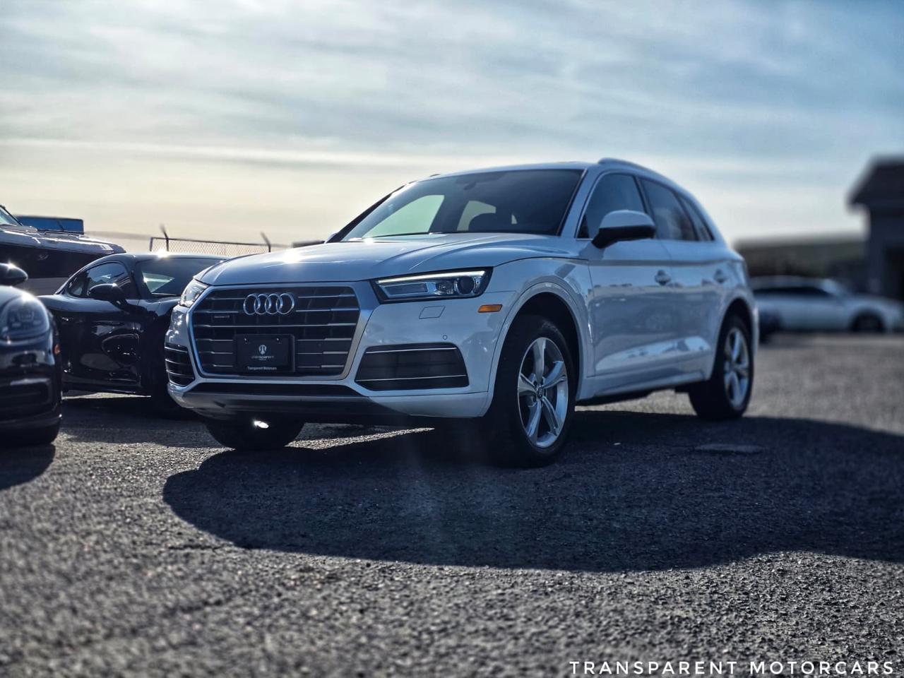 Transparent Motorcars is pleased to offer this beautiful 2018 Audi Q5 Premium Plus Quattro, With 108,170kms. It Features 252 HP 2.0L Turbocharged Engine Paired With 7-Speed S tronic Dual-Clutch Automatic Transmission Layered With Audi Quattro All-Wheel-Drive System, 19-Inch 5-Spoke Dynamic Design Wheels, LED Headlights, Power-Folding, Heated Side Mirrors With Integrated Turn Signals, Panoramic Sunroof, Power Liftgate With Hands-Free Operation, 8-Way Power-Adjustable Front Leather Seats, Dual-Zone Automatic Climate Control, MMI Navigation Plus System With 8.3-Inch Display, 10-Speaker Audi Sound System, Bluetooth, Apple CarPlay, And Android Auto, Forward Collision Warning With Automatic Braking, Rearview Camera With Front And Rear Parking Sensors, Heated Steering Wheel With Shift Paddles, And Much More! <br/> <br/> <br/> Stock# G000238A Dealer # 50276 <br/> <br/> <br/> $995 Documentation Fee <br/> <br/> <br/> 3 Month Warranty Will Be Provided <br/> <br/> <br/> This vehicle has undergone a comprehensive 110-point inspection at our state-of-the-art service facility, covering: Powertrain, Suspension, Tire Tread Depth ,Brake Condition ,All Electrical Components <br/> <br/> <br/> *Each vehicle comes with a limited warranty for your peace of mind. <br/> <br/> <br/> *Free, full CARFAX Vehicle History Report available upon request. <br/> <br/> <br/> *We are a 5-star rated Google dealership, trusted by our customers. <br/> <br/> <br/> *Thousands of satisfied customers  we invite you to join our automotive family! <br/> <br/> <br/> *Complimentary pick-up service from the airport, ferry terminal, or SkyTrain station is available. <br/> <br/> <br/> *For details on our refund and buyback policy, please contact our team directly. <br/> <br/> <br/> At our dealership, we pride ourselves on building lasting relationships with our customers. Were not just a one-time dealer  we are committed to being your trusted partner for all your vehicle needs, now and in the future. From your initial purchase to ongoing service, we aim to exceed expectations every step of the way. <br/>