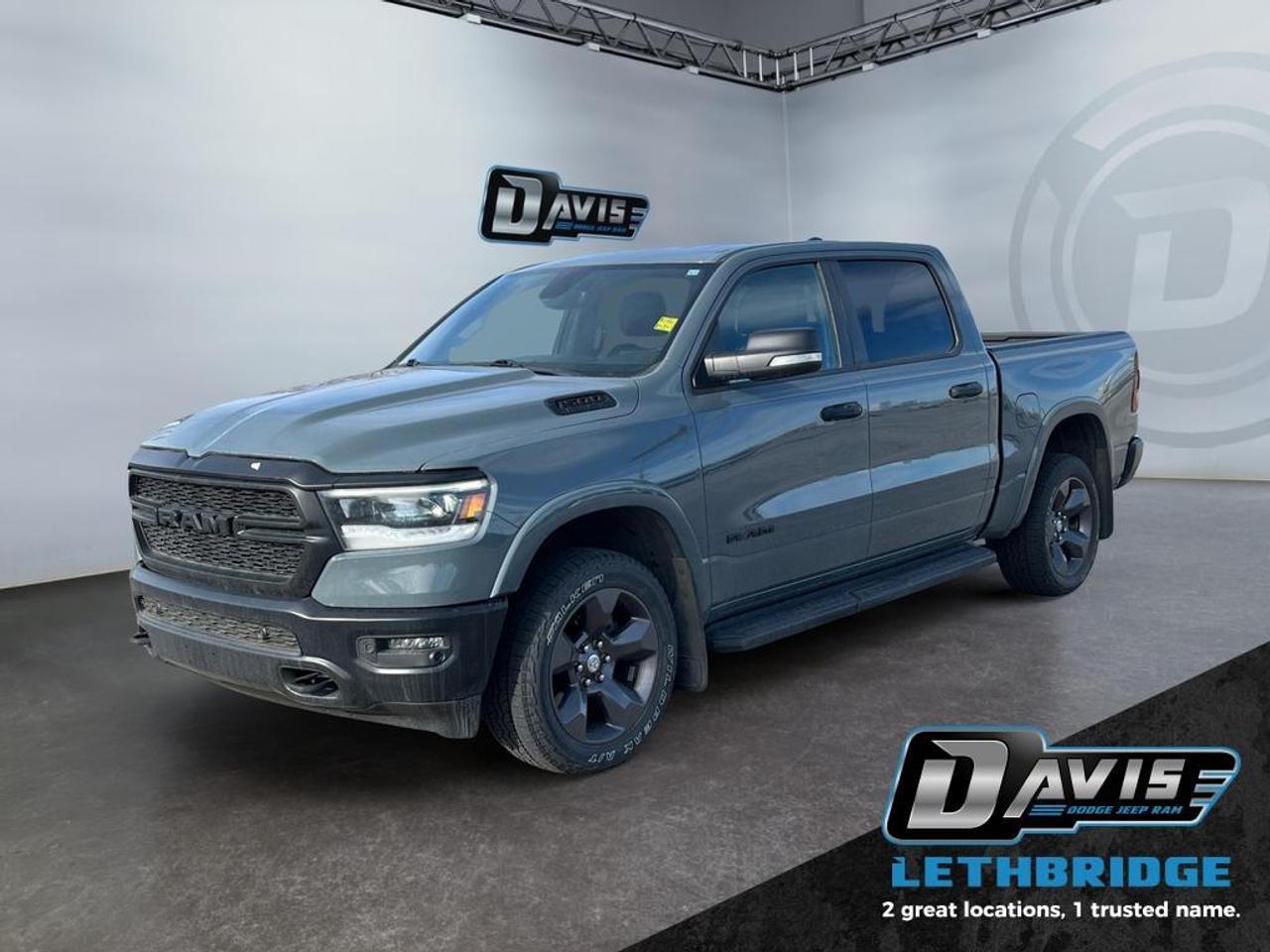 <b>Aluminum Wheels, Proximity Key, Touchscreen, Streaming Audio!<br /> <br /></b><br /> The 2021 Ram 1500 Big Horn Built to Serve Edition is a rugged and capable full-size truck designed to honor strength and durability while delivering impressive performance. Powered by a legendary 5.7L HEMI V8 engine paired with an 8-speed automatic transmission and 4x4 capability, this Crew Cab offers outstanding towing power and off-road confidence. Finished in bold Anvil Clear Coat with exclusive Built to Serve styling, black exterior accents, and aggressive stance, it stands out wherever it goes.<br /><br />Inside, this Ram blends toughness with comfort, featuring premium cloth/vinyl bucket seats, a power-adjustable driver seat with lumbar support, heated front seats, and a heated steering wheel. The cabin is equipped with an intuitive 8.4-inch Uconnect touchscreen with Apple CarPlay and Android Auto, a premium 9-speaker sound system with subwoofer, and multiple USB ports to keep you connected. Dual-zone automatic climate control, remote start, and a power sliding rear window add everyday convenience.<br /><br />Built for both work and play, this truck includes a Class IV hitch, trailer brake controller, tow hooks, skid plates, and an electronic locking rear axle for enhanced capability. Safety is well covered with Blind Spot Monitoring, ParkSense front and rear park assist, a backup camera, and advanced stability systems. With its unique styling, powerful V8 performance, and premium features, the 2021 Ram 1500 Big Horn Built to Serve is ready to handle any challenge.<br /> <br />To apply right now for financing use this link: <a href=https://lethbridge.davisdodge.ca/free-credit-check/ target=_blank rel=nofollow noopener noreferrer>https://lethbridge.davisdodge.ca/free-credit-check/</a><br /><br /> <br /><br />Locally Owned & Trusted for Over 35 Years  Davis Dodge in Lethbridge, AB <br /><br /> At Davis Dodge, weve proudly served the Lethbridge community for more than 35 years, offering an unparalleled car buying experience. Dont just take our word for itour Google reviews speak volumes about our commitment to exceptional service. <br /><br /> Delivery & At-Home Test Drives: Convenient options to suit your lifestyle. <br /><br /> Flexible Financing for Everyone: Get the vehicle you need with financing solutions tailored to your situation. <br /><br /> Full Mechanical Inspections & Professional Cleaning: Every vehicle is thoroughly inspected and cleaned before it hits our lot.<br /><br /> We take all makes and models on trade and offer competitive pricing with inventory that changes daily. Whether you're shopping for a Chrysler, Dodge, Jeep, RAM, or FIAT, our AMVIC Licensed dealership makes it easy to browse, buy, and drive away.<br /><br /> Located in Lethbridge, AB, we proudly serve customers in Fort Macleod, Taber, Claresholm, and Coaldale. Shop online or visit us today to experience the best in sales, service, and selection. Standard bank rates apply; taxes are additional.<br /><br /> Vehicle pricing offer shown expires 2026-04-30. <br /> Come by and check out our fleet of 60+ used cars and trucks and 110+ new cars and trucks for sale in Lethbridge. o~o