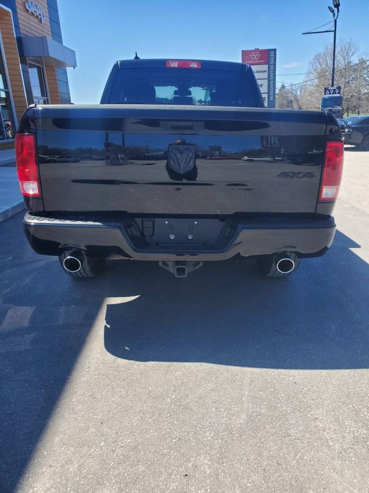 2021 RAM 1500 Classic SLT 4x4 Quad Cab 6'4" Box Photo