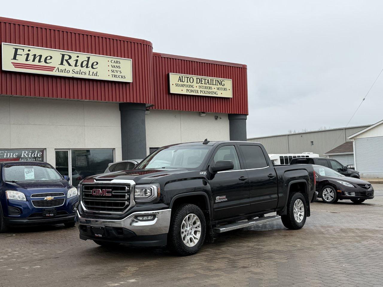 <p>2018 GMC Sierra 1500 SLE Crew Cab Z71 Kodiak Edition</p><p>5.3LTR V8<br>A/C<br>Telescopic tilt steering<br>Cruise<br>Power windows<br>Power locks<br>Power mirrors<br>Power seat (Drivers)<br>Heated seats<br>6 passengers<br>AM/FM radio<br>MY LINK  /  Bluetooth<br>258,000 HIGHWAY kms!<br>Factory remote start<br>Back up camera<br>Front & rear chrome bumpers<br>5.5ft box<br>Locking tail gate<br>Fog lights<br>Original Manitoba truck!</p><p>GVW: 7,200LBS<br>Gear: 3.42<br>Transmission: 6 speed, 6L-80<br>Towing: Approximately 9,100LBS</p><p>$20,975 Safetied<br>Financing and Warranty Available at Fine Ride Auto Sales Ltd<br>www.FineRideAutoSales.ca</p><p>Call: 204-415-3300 or 1-855-854-3300<br>Text: 204-226-1790<br>View in person at: Unit 3-3000 Main Street</p><p>DLR# 4614<br>**Plus applicable taxes**</p><p></p><p><span style=color:#000000;><span style=font-family:book antiqua, palatino, serif;font-size:14pt;>Monday                9am to 6pm</span></span><br><span style=color:#000000;><span style=font-family:book antiqua, palatino, serif;font-size:14pt;>Tuesday               9am to 6pm</span></span><br><span style=color:#000000;><span style=font-family:book antiqua, palatino, serif;font-size:14pt;>Wednesday               9am to 6pm</span></span><br><span style=color:#000000;><span style=font-family:book antiqua, palatino, serif;font-size:14pt;>Thursday                9am to 6pm</span></span><br><span style=color:#000000;><span style=font-family:book antiqua, palatino, serif;font-size:14pt;>Friday                9am to 5pm</span></span><br><span style=color:#000000;><span style=font-family:book antiqua, palatino, serif;font-size:14pt;>Saturday                             10am to 2pm</span></span><br><span style=color:#000000;><span style=font-family:book antiqua, palatino, serif;font-size:14pt;>Sunday                    CLOSED</span></span></p>
