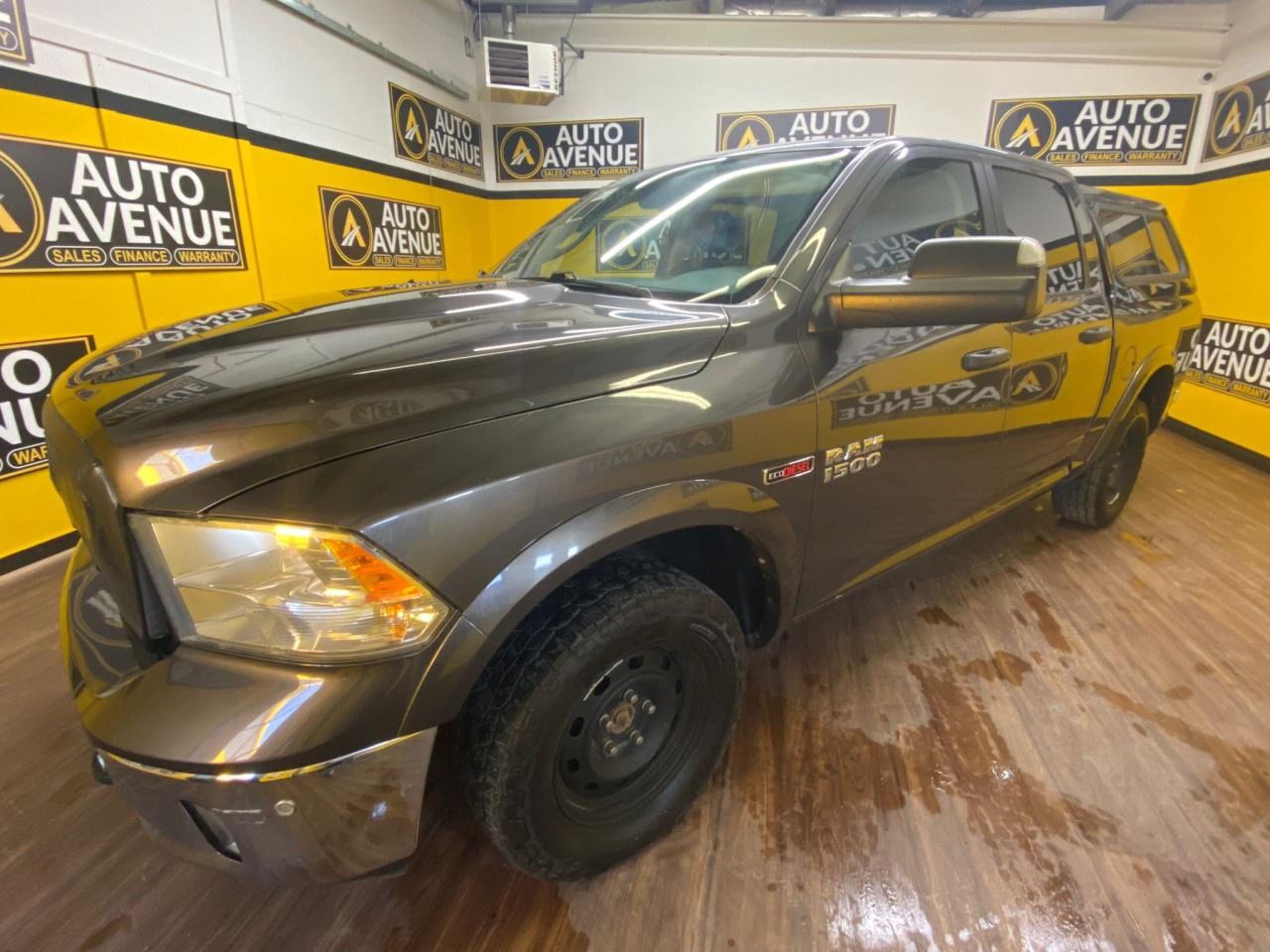 TACKLE ANY TERRAIN WITH THE 2018 RAM 1500 OUTDOORSMAN 4X4 CREW CAB 57 BOX! POWERED BY A 3.0L V6 ECODIESEL ENGINE AND PAIRED WITH AN 8-SPEED AUTOMATIC TRANSMISSION, THIS TRUCK DELIVERS IMPRESSIVE FUEL EFFICIENCY AND PERFORMANCE, WHETHER YOURE OFF-ROADING OR HAULING CARGO. WITH 4-WHEEL DRIVE, THE OUTDOORSMAN IS READY TO HANDLE ANY ADVENTURE.<br /><br />INSIDE, THE SPACIOUS CREW CAB SEATS UP TO FIVE AND FEATURES CLOTH UPHOLSTERY FOR COMFORT ON LONG DRIVES. STAY CONNECTED WITH THE UCONNECT 3 SYSTEM, FEATURING A 5-INCH DISPLAY, BLUETOOTH HANDS-FREE TECHNOLOGY, AND USB PORTS. ENJOY CONVENIENCE WITH A POWER DRIVERS SEAT, TILT-AND-TELESCOPING STEERING WHEEL, AND CRUISE CONTROL.<br /><br />THE OUTDOORSMAN TRIM COMES EQUIPPED WITH FOG LIGHTS, RUNNING BOARDS, AND A HEAVY-DUTY SUSPENSION, MAKING IT READY FOR ANY OFF-ROAD CHALLENGE. SAFETY FEATURES INCLUDE A REARVIEW CAMERA, PARKING SENSORS, TRACTION CONTROL, AND STABILITY CONTROL, GIVING YOU CONFIDENCE BEHIND THE WHEEL.<br /><br />THE 2018 RAM 1500 OUTDOORSMAN IS THE ULTIMATE COMBINATION OF RUGGED CAPABILITY AND EVERYDAY COMFORT &mdash; READY FOR YOUR NEXT ADVENTURE!<br /><br />AUTO AVENUE IS AN AMVIC LICENSED DEALERSHIP, COMMITTED TO PROVIDING EXCEPTIONAL SERVICE AND QUALITY VEHICLES WITH FLEXIBLE PAYMENT OPTIONS. <br /><br />