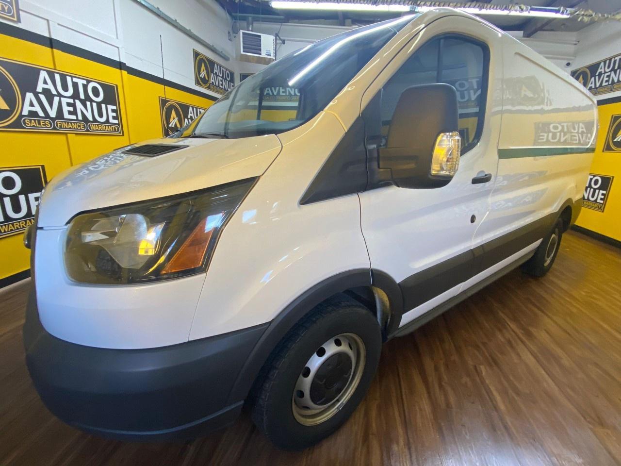 A 2018 Ford T-150 low-roof RWD Transit is a rear-wheel-drive van powered by a 3.7L V6 engine and a 6-speed automatic transmission. Its a work-oriented vehicle with a standard low roof, available with different wheelbases like the 130-inch or 148-inch, depending on the specific model. The van is known for its low step-in height, offering a functional cargo or passenger area, and comes equipped with features such as a standard rearview camera, power windows, and a sliding rear passenger-side door.<br /> AUTO AVENUE IS AN AMVIC LICENSED DEALERSHIP, COMMITTED TO PROVIDING EXCEPTIONAL SERVICE AND QUALITY VEHICLES WITH FLEXIBLE PAYMENT OPTIONS. <br/> GIVE US A CALL AT (403) 438-8884 OR EMAIL SALES@AUTOAVENUE.COM. WE&rsquo;RE LOCATED AT 211 EAST LAKE CRESCENT NE, AIRDRIE, AB T4A 2H7. <br/> AUTO AVENUE: YOUR DESTINATION FOR QUALITY CARS AND FLEXIBLE PAYMENTS. <br/>