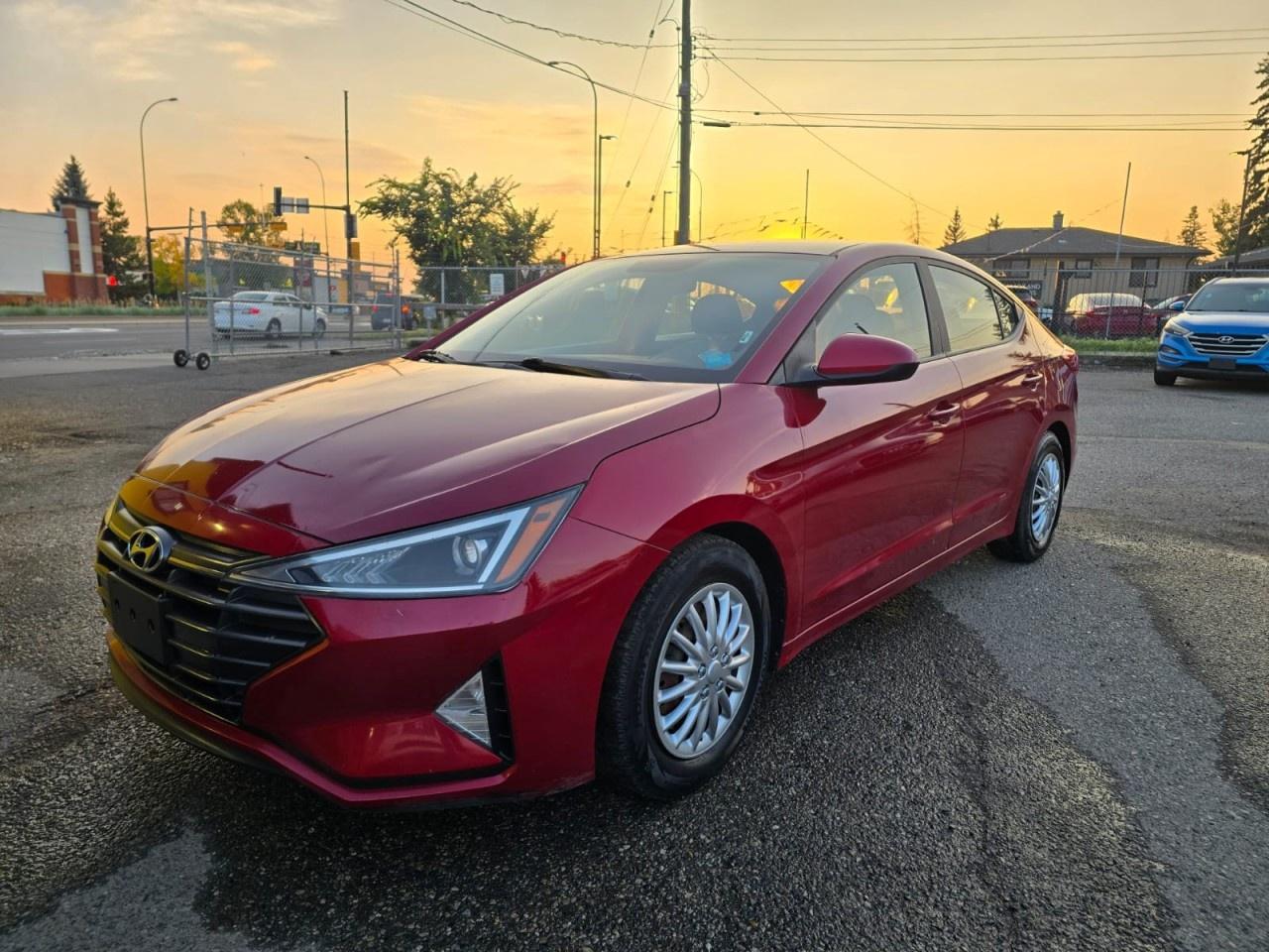 ENJOY RELIABILITY, COMFORT, AND EFFICIENT PERFORMANCE WITH THIS 2019 HYUNDAI ELANTRA ESSENTIAL. THIS COMPACT SEDAN OFFERS A SMOOTH RIDE, RESPONSIVE HANDLING, AND A PRACTICAL INTERIOR PERFECT FOR DAILY COMMUTES OR WEEKEND DRIVES. STANDARD FEATURES INCLUDE AIR CONDITIONING, POWER WINDOWS AND LOCKS, CRUISE CONTROL, AND ADVANCED SAFETY SYSTEMS SUCH AS MULTIPLE AIRBAGS AND STABILITY CONTROL FOR PEACE OF MIND ON EVERY TRIP. WITH ITS COMFORTABLE CABIN AND SATISFYING FUEL ECONOMY, THE ELANTRA ESSENTIAL DELIVERS VALUE AND DEPENDABILITY IN ONE PACKAGE. DON&rsquo;T WAIT&mdash;CONTACT US TODAY TO SCHEDULE YOUR TEST DRIVE AND EXPERIENCE IT FOR YOURSELF!<br /><br />AUTO AVENUE IS AN AMVIC LICENSED DEALERSHIP, COMMITTED TO PROVIDING EXCEPTIONAL SERVICE AND QUALITY VEHICLES WITH FLEXIBLE PAYMENT OPTIONS. <br/>