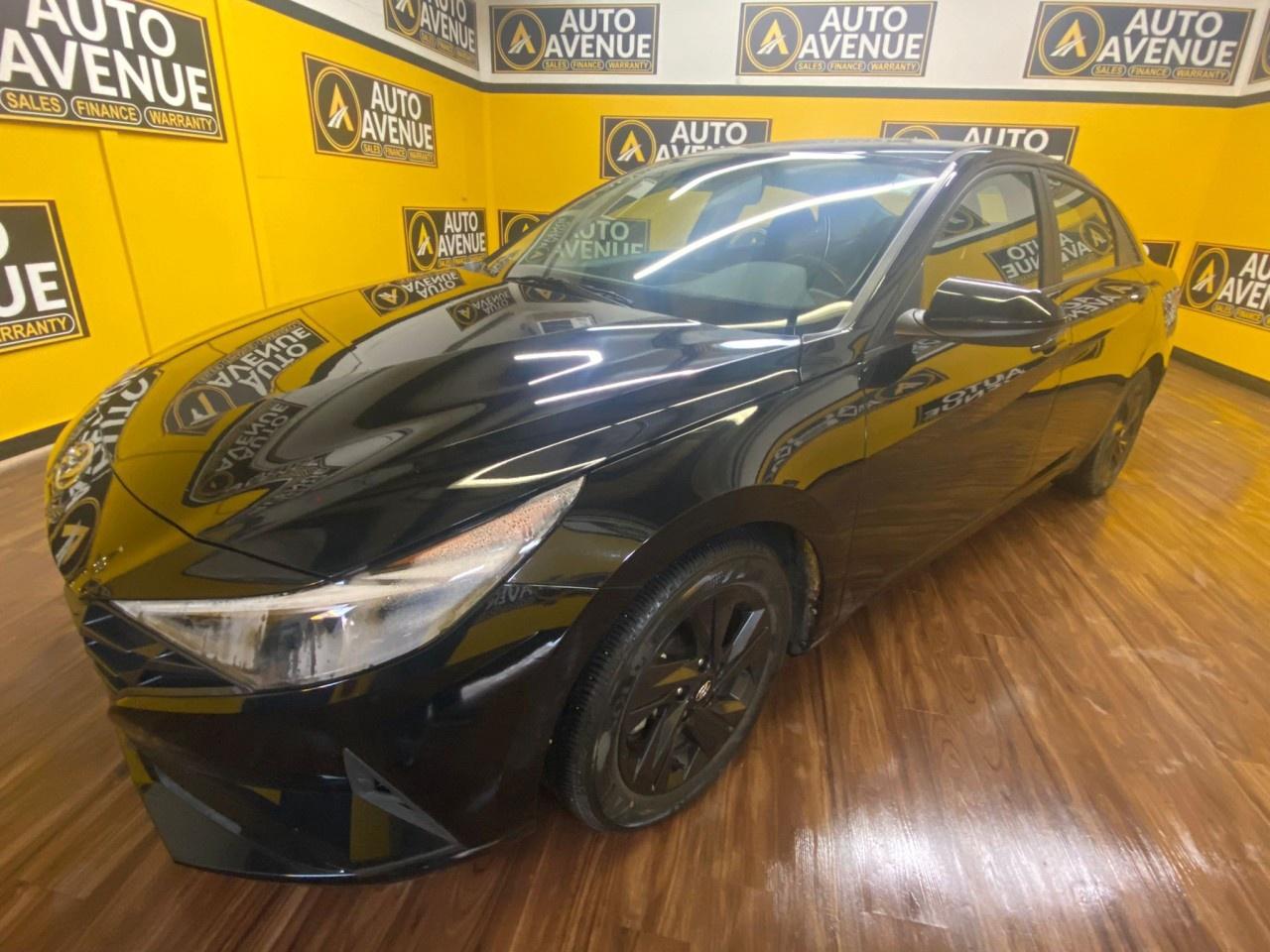 Auto Avenue Airdrie is honored to present a wonderful example of pure vehicle design... this 2021 Hyundai Elantra Essential only has 48,398km on it and could potentially be the vehicle of your dreams!<br /><br />Introducing the redesigned 2021 Hyundai Elantra, a compact sedan that challenges the competition with its striking style, impressive fuel efficiency, and a host of modern tech features. This Essential IVT model offers incredible value, making it the perfect choice for commuters, students, or anyone looking for a reliable and affordable daily driver.<br />Key features of this vehicle include:<br />Fuel-sipping IVT transmission: The responsive and smooth Intelligent Variable Transmission helps the 2.0L 4-cylinder engine achieve excellent fuel economy, rated as low as 5.7 L/100 km on the highway.<br />Wireless Apple CarPlay and Android Auto: Seamlessly integrate your smartphone with the standard 8.0-inch touchscreen for easy access to navigation, music, and more&mdash;all without needing a cable.<br />Essential winter-ready comfort: Standard heated front seats ensure you and your front passenger stay warm and comfortable on cold Canadian mornings.<br />Modern and spacious interior: The 2021 redesign gave the Elantra a stylish, upscale cabin with a driver-centric layout and ample legroom in both the front and rear seats. The spacious trunk also offers 402 L of storage for groceries, luggage, and gear.<br />Standard safety features: This model comes equipped with important safety features, including Forward Collision-Avoidance Assist with Pedestrian Detection, Lane Keeping Assist, and a rearview camera with dynamic guidelines.<br />Striking exterior design: The Elantras bold, angular Parametric Dynamics exterior styling stands out from the crowd, giving it a premium look usually reserved for more expensive vehicles.<br />This 2021 Elantra Essential is a smart buy for anyone seeking reliability, great gas mileage, and impressive technology in a stylish package. Dont miss your chance to own this fantastic compact sedan.<br /> Its not often you find just the vehicle you are looking for AND with low mileage. This is your chance to take home a pre-owned and barely driven Hyundai Elantra. Based on the superb condition of this vehicle, along with the options and color, this Hyundai Elantra Essential is sure to sell fast. <br/> This is about the time when youre saying it is too good to be true, and let us be the ones to tell you, it is absolutely true. The look is unmistakably Hyundai, the smooth contours and cutting-edge technology of this Hyundai Elantra Essential will definitely turn heads.<br /><br />AUTO AVENUE IS AN AMVIC LICENSED DEALERSHIP, COMMITTED TO PROVIDING EXCEPTIONAL SERVICE AND QUALITY VEHICLES WITH FLEXIBLE PAYMENT OPTIONS.<br /><br />GIVE US A CALL AT (403) 438-8884 OR EMAIL SALES@AUTOAVENUE.COM. WE&rsquo;RE LOCATED AT 211 EAST LAKE CRESCENT NE, AIRDRIE, AB T4A 2H7.<br /><br />AUTO AVENUE: YOUR DESTINATION FOR QUALITY CARS AND FLEXIBLE PAYMENTS. <br/>