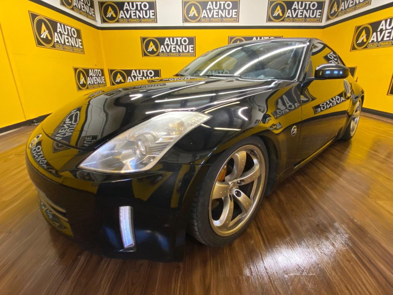 2007 Nissan 350Z Grand Touring &ndash; Iconic Sports Performance in Black<br /><br />Auto Avenue Airdrie is excited to offer this 2007 Nissan 350Z Grand Touring.<br /><br />Turn heads and feel the thrill every time you drive with this 2007 Nissan 350Z Grand Touring. With only 112,486 km, this sleek Black coupe delivers an exhilarating rear-wheel-drive experience that true sports car enthusiasts crave.<br /><br />Powered by a 3.5L V6 engine and paired with a 6-speed manual transmission, the 350Z offers responsive acceleration, precise handling, and a connected driving feel that makes every road your playground. Its aggressive styling, low stance, and aerodynamic lines signal performance before you even press the accelerator.<br /><br />Step inside to a Black leather interior with heated, power-adjustable seats that keep you comfortable during spirited drives. The driver-focused cockpit ensures everything is within reach, while premium audio and modern conveniences round out a cabin built for enjoyment.<br /><br />Perfect for those who value style, power, and engagement, this 350Z Grand Touring combines classic sports car DNA with modern comfort. Whether carving corners on the weekend or making a statement on your daily commute, this coupe delivers a driving experience like no other.<br /> AUTO AVENUE IS AN AMVIC LICENSED DEALERSHIP, COMMITTED TO PROVIDING EXCEPTIONAL SERVICE AND QUALITY VEHICLES WITH FLEXIBLE PAYMENT OPTIONS. <br/> GIVE US A CALL AT (403) 438-8884 OR EMAIL SALES@AUTOAVENUE.COM. WE&rsquo;RE LOCATED AT 211 EAST LAKE CRESCENT NE, AIRDRIE, AB T4A 2H7. <br/> AUTO AVENUE: YOUR DESTINATION FOR QUALITY CARS AND FLEXIBLE PAYMENTS. <br/> <br /> <br/>