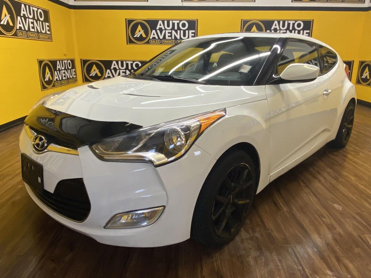 FALL IN LOVE WITH SPORTY STYLE, AGILE HANDLING, AND PRACTICAL EVERYDAY PERFORMANCE IN THIS 2013 HYUNDAI VELOSTER WITH TECH PACKAGE. THIS UNIQUE HATCHBACK OFFERS A FUNTODRIVE EXPERIENCE, A WELLAPPOINTED INTERIOR, AND STANDARD FEATURES LIKE AIR CONDITIONING, POWER WINDOWS AND LOCKS, CRUISE CONTROL, AND ADVANCED SAFETY SYSTEMS INCLUDING MULTIPLE AIRBAGS AND STABILITY CONTROL FOR PEACE OF MIND ON EVERY DRIVE. WITH ITS DISTINCTIVE DESIGN, COMFORTABLE CABIN, AND TECHNOLOGY ENHANCEMENTS, THE VELOSTER COMBINES FUN AND FUNCTION IN ONE EYECATCHING PACKAGE. DON&rsquo;T WAIT&mdash;CONTACT US TODAY TO SCHEDULE YOUR TEST DRIVE AND EXPERIENCE IT FOR YOURSELF! <br /><br />AUTO AVENUE IS AN AMVIC LICENSED DEALERSHIP, COMMITTED TO PROVIDING EXCEPTIONAL SERVICE AND QUALITY VEHICLES WITH FLEXIBLE PAYMENT OPTIONS. <br/>