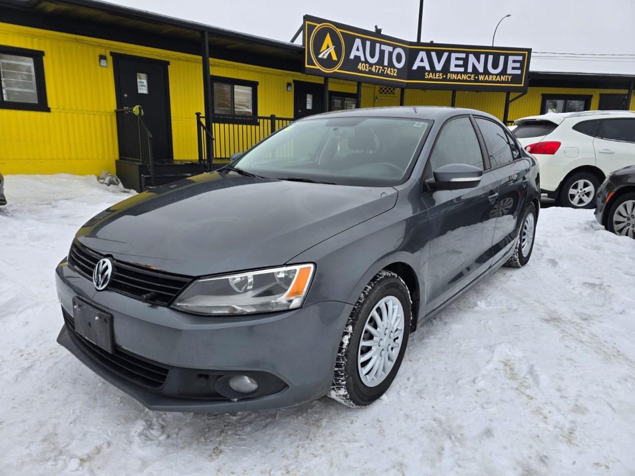 ENJOY COMFORTABLE EVERYDAY DRIVING, PRACTICAL STYLE, AND EFFICIENT PERFORMANCE WITH THIS 2014 VOLKSWAGEN JETTA SEDAN TRENDLINE. THIS WELLDESIGNED SEDAN OFFERS A SMOOTH RIDE, RESPONSIVE HANDLING, AND A USERFRIENDLY INTERIOR PERFECT FOR DAILY COMMUTES OR WEEKEND TRIPS. STANDARD FEATURES INCLUDE AIR CONDITIONING, POWER WINDOWS AND LOCKS, CRUISE CONTROL, AND ADVANCED SAFETY SYSTEMS SUCH AS MULTIPLE AIRBAGS AND STABILITY CONTROL FOR PEACE OF MIND ON EVERY DRIVE. WITH ITS SATISFYING FUEL ECONOMY AND COMFORTABLE CABIN, THE JETTA TRENDLINE DELIVERS VALUE AND DEPENDABILITY IN ONE PRACTICAL PACKAGE. DON&rsquo;T WAIT&mdash;CONTACT US TODAY TO SCHEDULE YOUR TEST DRIVE AND EXPERIENCE IT FOR YOURSELF!<br /><br />AUTO AVENUE IS AN AMVIC LICENSED DEALERSHIP, COMMITTED TO PROVIDING EXCEPTIONAL SERVICE AND QUALITY VEHICLES WITH FLEXIBLE PAYMENT OPTIONS. <br/>