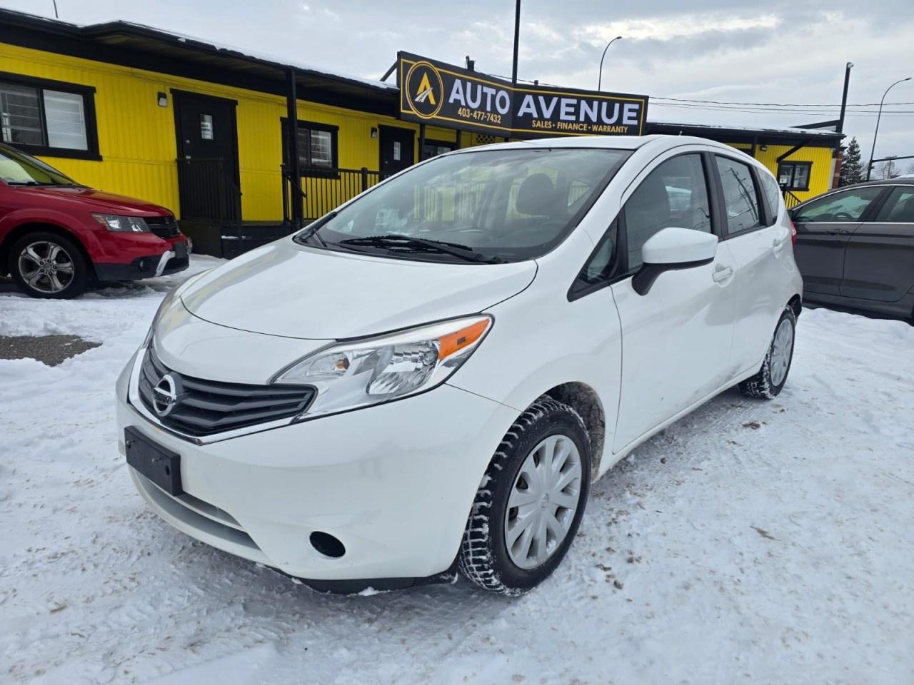 Auto Avenue 17th AVE is pleased to present this 2015 Nissan Versa Note SV, a practical, economical, and well-maintained hatchback that perfectly blends efficiency, comfort, and everyday usability. With only 85,398 km, this Versa Note stands out with its exceptionally low mileage and impressive overall condition. <br/> The Nissan Versa Note S is known for its fuel efficiency, smart engineering, and excellent visibility. Inside, it offers a comfortable and spacious cabin for both driver and passengers, along with generous cargo capacity for a vehicle of its size. <br/> This particular model comes equipped with a large multimedia screen and a backup camera, making parking and maneuvering effortless, as well as an automatic transmission that provides smooth and easy driving in all conditions. <br/> For drivers seeking a reliable, economical, and extremely well-kept compact hatchback, this 2015 Nissan Versa Note SV is an outstanding choice. <br/> This vehicle won&rsquo;t last long &mdash; if you&rsquo;d like more information or wish to arrange a viewing, please contact Auto Avenue 17th AVE today.<br /><br /> <br/> AUTO AVENUE IS AN AMVIC LICENSED DEALERSHIP, COMMITTED TO PROVIDING EXCEPTIONAL SERVICE AND QUALITY VEHICLES WITH FLEXIBLE PAYMENT OPTIONS. <br/> GIVE US A CALL AT (403) 477-7432 OR EMAIL SALES@AUTOAVENUE.COM. WE&rsquo;RE LOCATED AT 1739 51 STREET SE, CALGARY, AB T2A 1T2. <br/> AUTO AVENUE: YOUR DESTINATION FOR QUALITY CARS AND FLEXIBLE PAYMENTS. <br/>