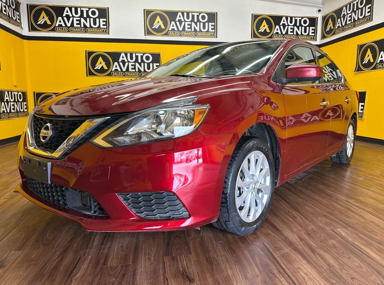 EXPERIENCE RELIABLE COMFORT, EFFICIENT PERFORMANCE, AND EVERYDAY PRACTICALITY WITH THIS 2019 NISSAN SENTRA SV. THIS WELLROUNDED SEDAN OFFERS A SMOOTH RIDE, RESPONSIVE HANDLING, AND A COMFORTABLE INTERIOR PERFECT FOR DAILY COMMUTES OR WEEKEND DRIVES. STANDARD FEATURES INCLUDE AIR CONDITIONING, POWER WINDOWS AND LOCKS, CRUISE CONTROL, AND ADVANCED SAFETY SYSTEMS SUCH AS MULTIPLE AIRBAGS AND STABILITY CONTROL FOR PEACE OF MIND ON EVERY DRIVE. WITH ITS SATISFYING FUEL ECONOMY, USERFRIENDLY CABIN, AND GENEROUS CARGO SPACE, THE SENTRA SV DELIVERS BOTH VALUE AND COMFORT IN ONE DEPENDABLE PACKAGE. DON&rsquo;T WAIT&mdash;CONTACT US TODAY TO SCHEDULE YOUR TEST DRIVE AND EXPERIENCE IT FOR YOURSELF!<br /><br />AUTO AVENUE IS AN AMVIC LICENSED DEALERSHIP, COMMITTED TO PROVIDING EXCEPTIONAL SERVICE AND QUALITY VEHICLES WITH FLEXIBLE PAYMENT OPTIONS. <br/>