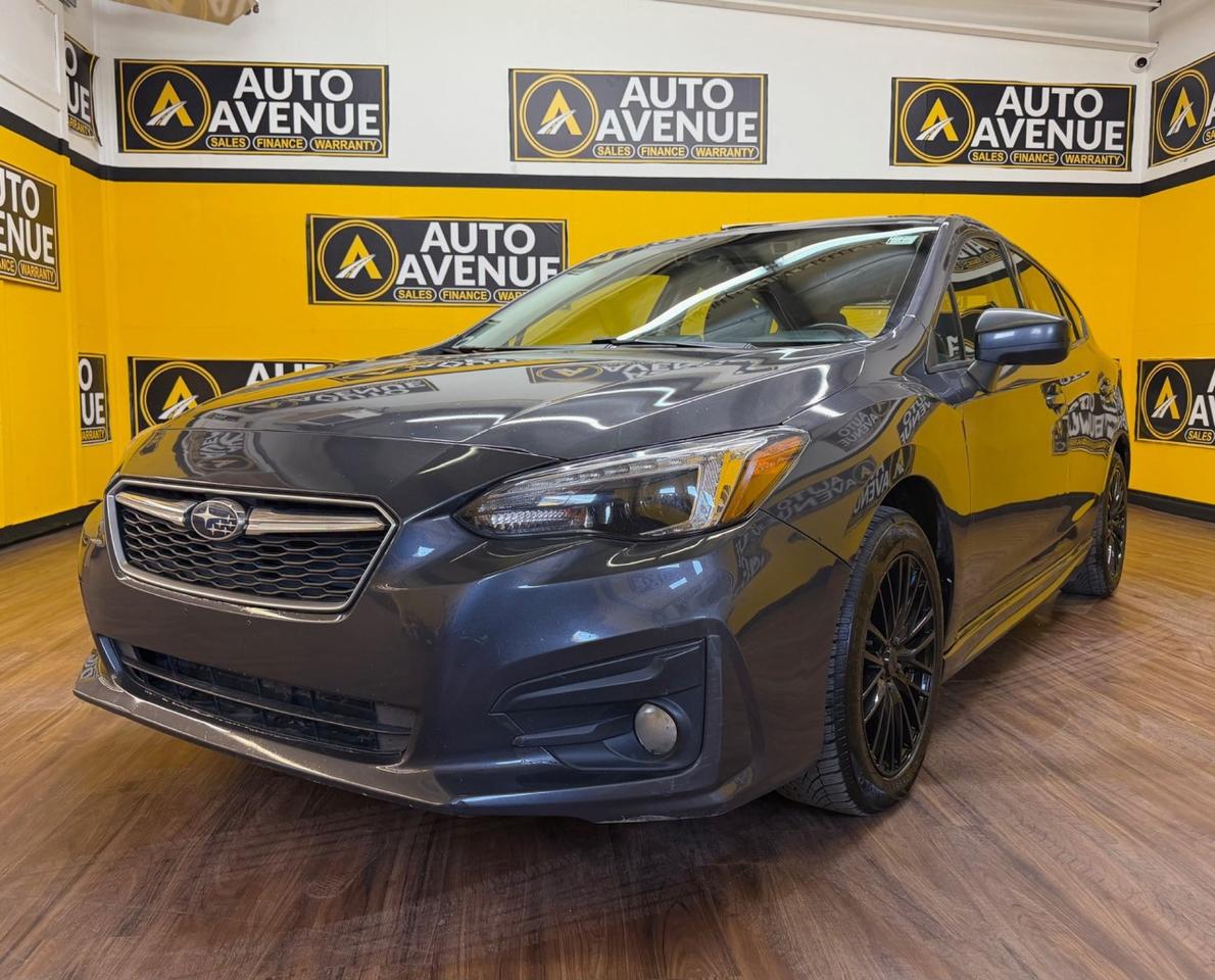 Check out this sporty and reliable pre-owned 2018 Subaru Impreza Sport now available at Auto Avenue Airdrie. <br/> The Subaru Impreza is known for its exceptional balance of safety, efficiency, and all-weather capability. Equipped with Subaru&rsquo;s renowned symmetrical AWD system, this vehicle delivers outstanding traction and control, making it a perfect fit for Alberta&rsquo;s ever-changing road conditions. <br/> This Sport trim adds an extra level of style and driving enjoyment, combining sleek design with responsive handling and impressive fuel efficiency. It&rsquo;s a compact car that feels confident, capable, and fun behind the wheel. <br/> Inside, you&rsquo;ll find a well-equipped and comfortable cabin featuring a sunroof that brings in natural light and enhances every drive. You&rsquo;ll also appreciate the heated front seats, keeping you warm during cold mornings, and a backup camera that makes parking and reversing simple and safe. <br/> With its low mileage, strong reputation for longevity, and versatile performance, this 2018 Subaru Impreza Sport stands out as an excellent value for anyone seeking a dependable and stylish AWD vehicle. <br/> Safe. Sporty. Ready for All Seasons. Subaru. | Auto Avenue Airdrie<br /><br />AUTO AVENUE IS AN AMVIC LICENSED DEALERSHIP, COMMITTED TO PROVIDING EXCEPTIONAL SERVICE AND QUALITY VEHICLES WITH FLEXIBLE PAYMENT OPTIONS.<br />GIVE US A CALL AT (403) 438-8884 OR EMAIL SALES@AUTOAVENUE.COM<br />WE&rsquo;RE LOCATED AT 211 EAST LAKE CRESCENT NE, AIRDRIE, AB T4A 2H7.<br />AUTO AVENUE: YOUR DESTINATION FOR QUALITY CARS AND FLEXIBLE PAYMENTS. <br/>