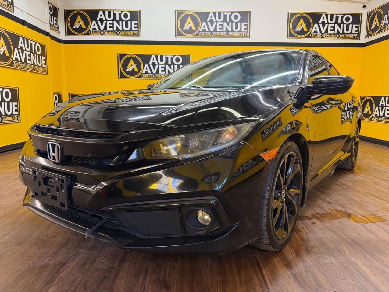 Check out this stylish and well-maintained pre-owned 2021 Honda Civic Sedan Sport now available at Auto Avenue Airdrie. <br/> The Honda Civic has built a reputation for reliability, efficiency, and modern design&mdash;and this Sport version takes it up a notch with a more dynamic look and engaging driving experience. With its sleek body lines and responsive handling, the Civic Sport is perfect for both city driving and longer road trips. <br/> Inside, you&rsquo;ll find a thoughtfully designed cabin packed with comfort and technology. Enjoy heated front seats, ideal for cold Canadian mornings, along with a power sunroof that brings in fresh air and natural light for a more enjoyable ride. <br/> Technology is front and center with a large touchscreen display that includes a backup camera, making parking and reversing easier and safer. Everything is designed to keep you connected, comfortable, and in control on every drive. <br/> With its strong reputation, sporty styling, and practical features, this 2021 Honda Civic Sedan Sport is an excellent choice for drivers who want a reliable car with a bit of extra flair. <br/> Sporty. Smart. Reliable. Honda. | Auto Avenue Airdrie<br /><br />AUTO AVENUE IS AN AMVIC LICENSED DEALERSHIP, COMMITTED TO PROVIDING EXCEPTIONAL SERVICE AND QUALITY VEHICLES WITH FLEXIBLE PAYMENT OPTIONS.<br />GIVE US A CALL AT (403) 438-8884 OR EMAIL SALES@AUTOAVENUE.COM<br />WE&rsquo;RE LOCATED AT 211 EAST LAKE CRESCENT NE, AIRDRIE, AB T4A 2H7.<br />AUTO AVENUE: YOUR DESTINATION FOR QUALITY CARS AND FLEXIBLE PAYMENTS.<br /><br /><br /> <br/>