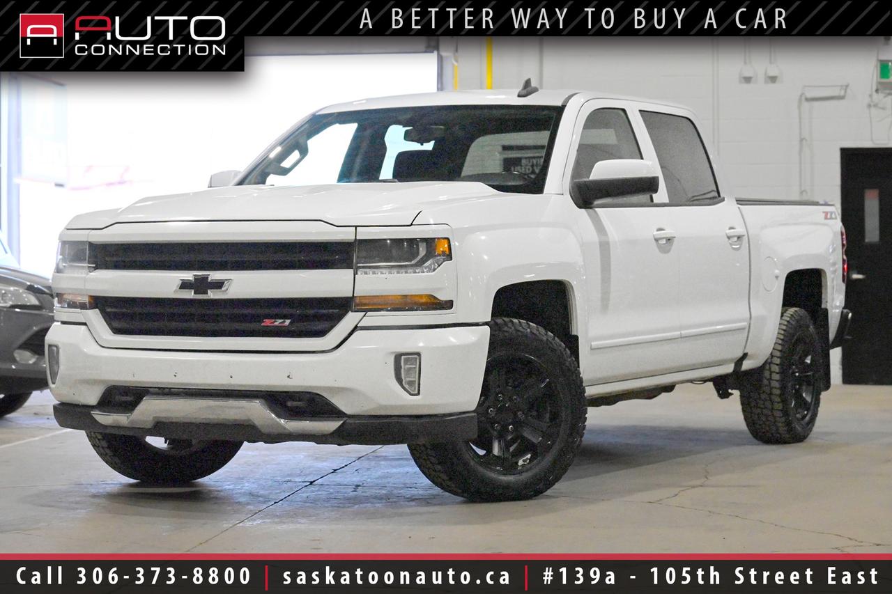 <p><span><font color=#000000><span>Financing & Warranty Available!</span><span><br></span></font></span><span><br></span><b><span>Crew Cab w/ 5.8ft. Box - Accident Free! - Exceptional Condition</span><span><br></span></b><span><br>This accident-free <b>2018 Chevrolet Silverado 1500 LT Z71 Crew Cab</b> in Summit White delivers the perfect balance of rugged capability and everyday comfort. Under the hood, the proven 5.3L EcoTec3 V8 paired with a 6-speed automatic transmission and 4x4 gives you the power and confidence to handle tough jobs or weekend adventures with ease. Equipped with the Z71 Off-Road Package, this truck is built to tackle rough terrain while maintaining a smooth, controlled ride on the highway. Inside, the spacious Crew Cab features a well-appointed Jet Black cloth interior with heated front seats, power-adjustable bucket seats, and dual-zone automatic climate control to keep everyone comfortable. The 8-inch touchscreen and Bose premium sound system create an enjoyable driving experience, while wireless charging and remote start add everyday convenience. Safety and visibility are enhanced with a rear vision camera, heated power mirrors, HID headlights, and LED fog lamps. When its time to tow, the Trailering Package with an integrated brake controller and locking rear differential ensures youre ready for the job. Finished with bold Z71 styling details and a clean, confident stance, this Silverado stands out as a dependable and well-equipped truck at Saskatoon Auto Connection.<br><br></span><span>Key Features:</span><span><br></span><span><br>- 4x4<br>- Z71 Off-Road & Appearance Packages<br>- True North Edition<br>- Heated Seats<br>- Remote Start<br>- Wireless Charging<br>- 7-Speaker Bose Premium Sound System w/ Subwoofer<br>- Rear Vision Camera<br>- 8-Inch Diagonal Colour Touchscreen<br>- Leather-Wrapped Steering Wheel<br>- Power-Adjustable Front Bucket Seats<br>- Dual-Zone Automatic Climate Control<br>- Rear Window Defogger<br>- 110V Auxiliary Power Outlet<br>- Heated Power Sideview Mirrors<br>- High-Intensity Discharge (HID) Headlights<br>- LED Fog Lamps<br>- Unique Z71 Gauge Cluster<br>- Black Chevrolet Front Bowtie Emblem<br>- Body-Colour Front & Rear Bumpers<br>- Body-Colour Grille Surround & Headlamp Bezels<br>- Tonneau Cover<br>- Trailering Package<br>- Integrated Trailer Brake Controller<br>- Hill Descent Control<br>- 3.08 Rear Axle Ratio<br>- Heavy-Duty Automatic Locking Rear Differential<br>- 6-Speed Automatic Transmission<br>- 5.3L EcoTec3 8-Cylinder Engine<br><br><b>Exterior Colour:</b> Summit White<br><b>Interior Colour:</b> Jet Black Cloth<br><br><b>Manufacturers Brochure:</b> </span><a href=https://www.auto-brochures.com/makes/Chevrolet/Silverado/Chevrolet_US%20Silverado_2018.pdf target=_blank><span>https://www.auto-brochures.com/makes/Chevrolet/Silverado/Chevrolet_US%20Silverado_2018.pdf</span></a><span><br><br></span><span>Unlock a full year of exclusive VIP benefits with your purchase! Enjoy 20% off labour, 25% off tires, free windshield stone chip repairs, and so much more. Visit saskatoonauto.ca for all the details.<br></span><span><br>Honesty Pricing eliminates the haggle hassle by providing you with our lowest possible selling price up front. In fact, it is the lowest price in our market, and we will prove it by disclosing a comprehensive market report of what our competitors are selling similar vehicles for.<br></span><span><br>This vehicle meets our Diamond Certification standard, which begins by selecting only premium quality vehicles and subjecting them to a much more comprehensive inspection process than typical dealerships use. Diamond Certified ensures a clean history, exceptional appearance and problem-free operation.<br></span><span><br>At Saskatoon Auto Connection we sell pre-owned automobiles the way we would like to buy them ourselves. Since 2008, we have been dedicated to providing the highest level of integrity and transparency in our industry, in combination with the highest quality vehicles at the most competitive prices in Saskatchewan. Our friendly staff is ready to positively redefine your expectations of the pre-owned automobile space.</span><span></span></p>