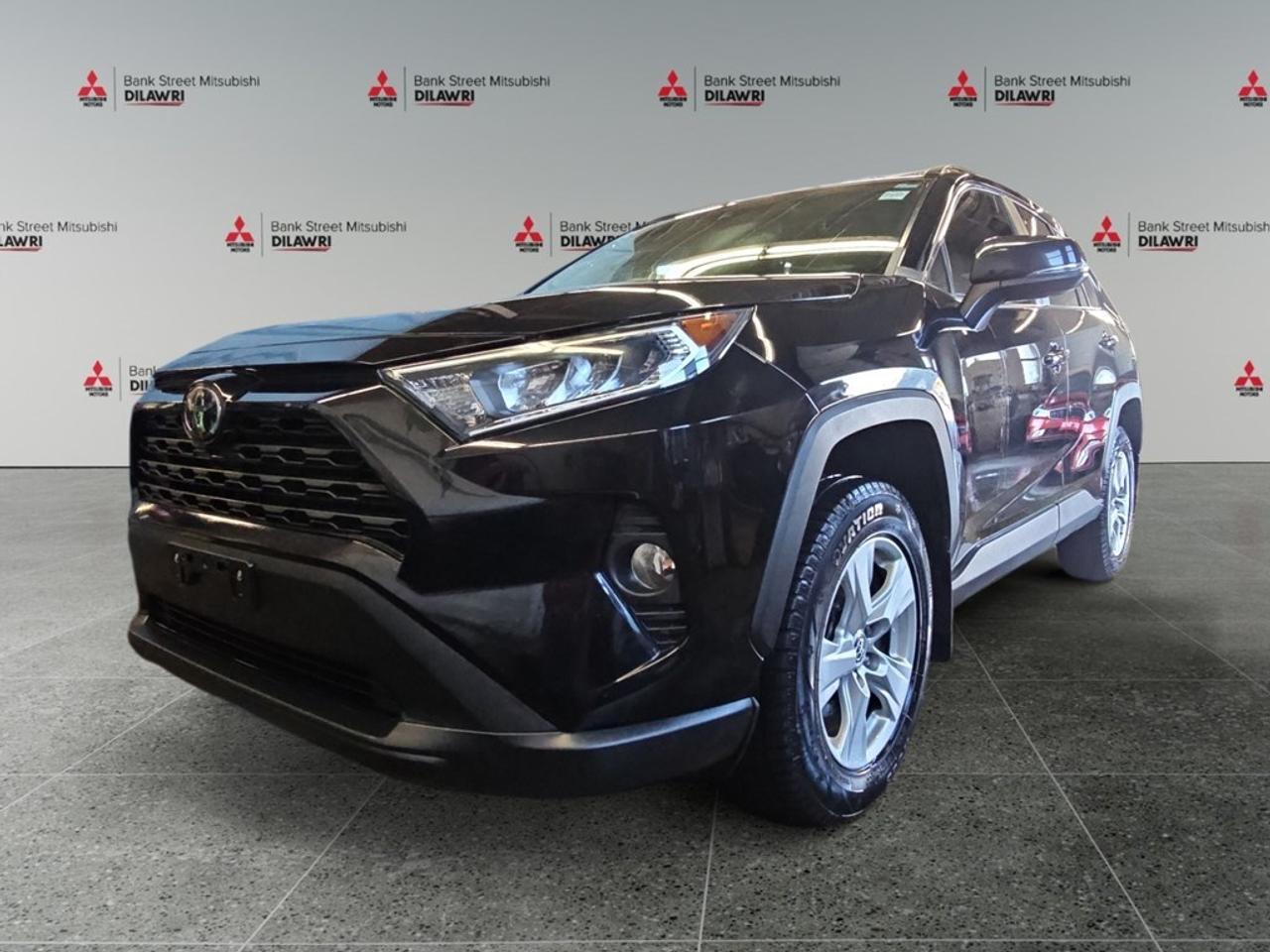 Balance of 5 year/100,000kms BASIC warranty and 10 year/160,000kms Factory Powertrain Warranty on ALL MITSUBISHI products! Best in the industry!!!! The 2019 Black Toyota RAV4 AWD XLE offers impressive control with its all-wheel-drive system, designed to handle a variety of road conditions with ease. This SUV boasts a sporty Black exterior that exudes a sense of style and sophistication. The spacious interior is equipped with comfortable heated seats, a leather steering wheel, and leatherette door trim inserts, ensuring every drive is a pleasurable experience. Stay connected and safe with a suite of advanced technology features including smart device integration, a backup camera, Bluetooth connection, and lane assist. The vehicle also features a sunroof/moonroof for enjoying the open sky, along with power seats and windows for added convenience. With its adaptive cruise control and brake assist, the 2019 Toyota RAV4 AWD XLE provides confidence and peace of mind on every journey. This SUV is an ideal choice for families or adventurers seeking a reliable and comfortable ride. Contact our dealership today to learn more about this exceptional vehicle and take it for a test drive.