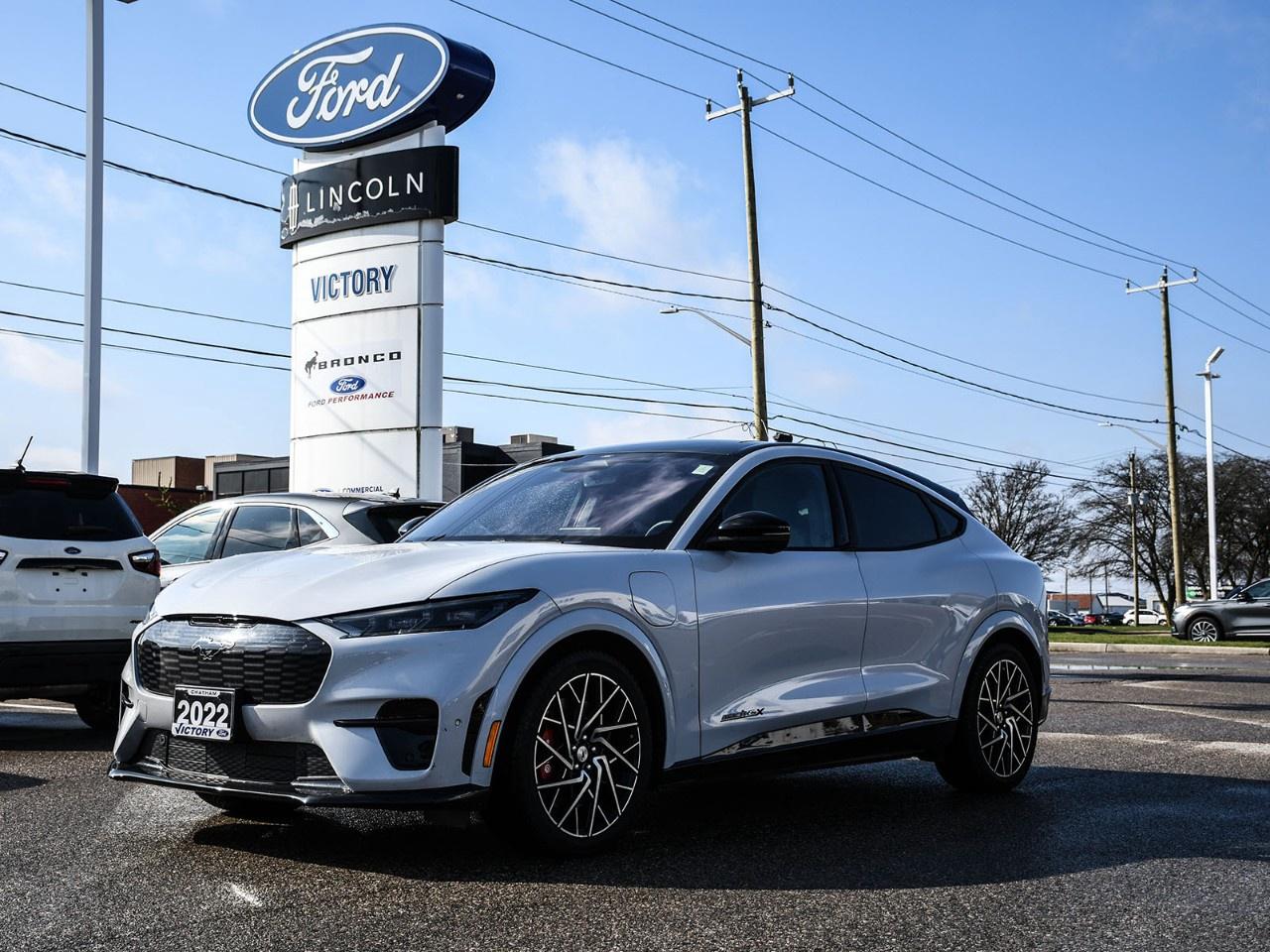 <h2>NOW AVAILABLE AT VICTORY FORD LINCOLN</h2><h1>2022 Ford Mustang Mach-E GT</h1><h3>Panoramic Fixed-Glass Roof  Ford Co-Pilot360 Active 2.0  High-Performance Electric SUV</h3><p>This 2022 Ford Mustang Mach-E GT delivers thrilling all-electric performance, cutting-edge technology, and bold Mustang-inspired styling. Equipped with a panoramic fixed-glass roof and Ford Co-Pilot360 Active 2.0, this Mach-E GT offers an exhilarating drive with advanced driver-assist features and premium comfort.</p><h3>POWER & PERFORMANCE</h3><ul><li><p>Dual Motor Electric Powertrain</p></li><li><p>All-Wheel Drive</p></li><li><p>Instant Torque & Rapid Acceleration</p></li><li><p>Performance-Tuned GT Suspension</p></li><li><p>Smooth, Silent Electric Drive</p></li><li><p>Selectable Drive Modes</p></li></ul><h3>FORD CO-PILOT360 ACTIVE 2.0</h3><ul><li><p>Adaptive Cruise Control with Stop & Go</p></li><li><p>Lane Centering</p></li><li><p>Intelligent Speed Assist</p></li><li><p>Advanced Driver Assistance Technology</p></li></ul><h3>EXTERIOR FEATURES</h3><ul><li><p>Panoramic Fixed-Glass Roof</p></li><li><p>LED Signature Lighting</p></li><li><p>Power Liftgate</p></li><li><p>Sport-Inspired GT Styling</p></li><li><p>Aerodynamic Design</p></li></ul><h3>INTERIOR & COMFORT</h3><ul><li><p>Performance Front Seats</p></li><li><p>Heated Front Seats & Steering Wheel</p></li><li><p>Dual-Zone Climate Control</p></li><li><p>Premium Materials Throughout</p></li><li><p>Spacious 5-Passenger Cabin</p></li><li><p>Quiet Electric Ride</p></li></ul><h3>TECHNOLOGY</h3><ul><li><p>Large Vertical Touchscreen Display</p></li><li><p>SYNC® 4A System</p></li><li><p>Navigation System</p></li><li><p>Apple CarPlay® & Android Auto</p></li><li><p>Premium B&O Sound System</p></li><li><p>Wireless Charging</p></li><li><p>Digital Driver Display</p></li></ul><h3>SAFETY & DRIVER ASSISTANCE</h3><ul><li><p>Ford Co-Pilot360</p></li><li><p>Pre-Collision Assist with Automatic Emergency Braking</p></li><li><p>Blind Spot Information System</p></li><li><p>Lane Keeping System</p></li><li><p>360° Camera</p></li><li><p>Rear Parking Sensors</p></li></ul><h3>HIGHLIGHTS</h3><ul><li><p>GT Performance Model</p></li><li><p>Panoramic Fixed-Glass Roof</p></li><li><p>Ford Co-Pilot360 Active 2.0</p></li><li><p>All-Electric Performance</p></li><li><p>Advanced Technology</p></li><li><p>Mustang-Inspired Design</p></li></ul><h3>Special Offer:</h3><p><strong>Peace of Mind Included:</strong> 3-Month Comprehensive Warranty (for vehicles under 10 years old & under 160,000 km) No-Haggle, Live Market Pricing  Transparent & Competitive All-Inclusive Pricing: Fees, Reconditioning, and Full Detailing Included (Taxes & Licensing Extra)</p><h4>Additional Details:</h4><p><strong>Keys:</strong> Standard with one key. Additional keys (if provided by the previous owner) included at no cost. Optional key purchases available upon request.</p><p><strong>Visit Victory Ford Lincoln Today</strong> Schedule your appointment to experience this exceptional vehicle.</p>