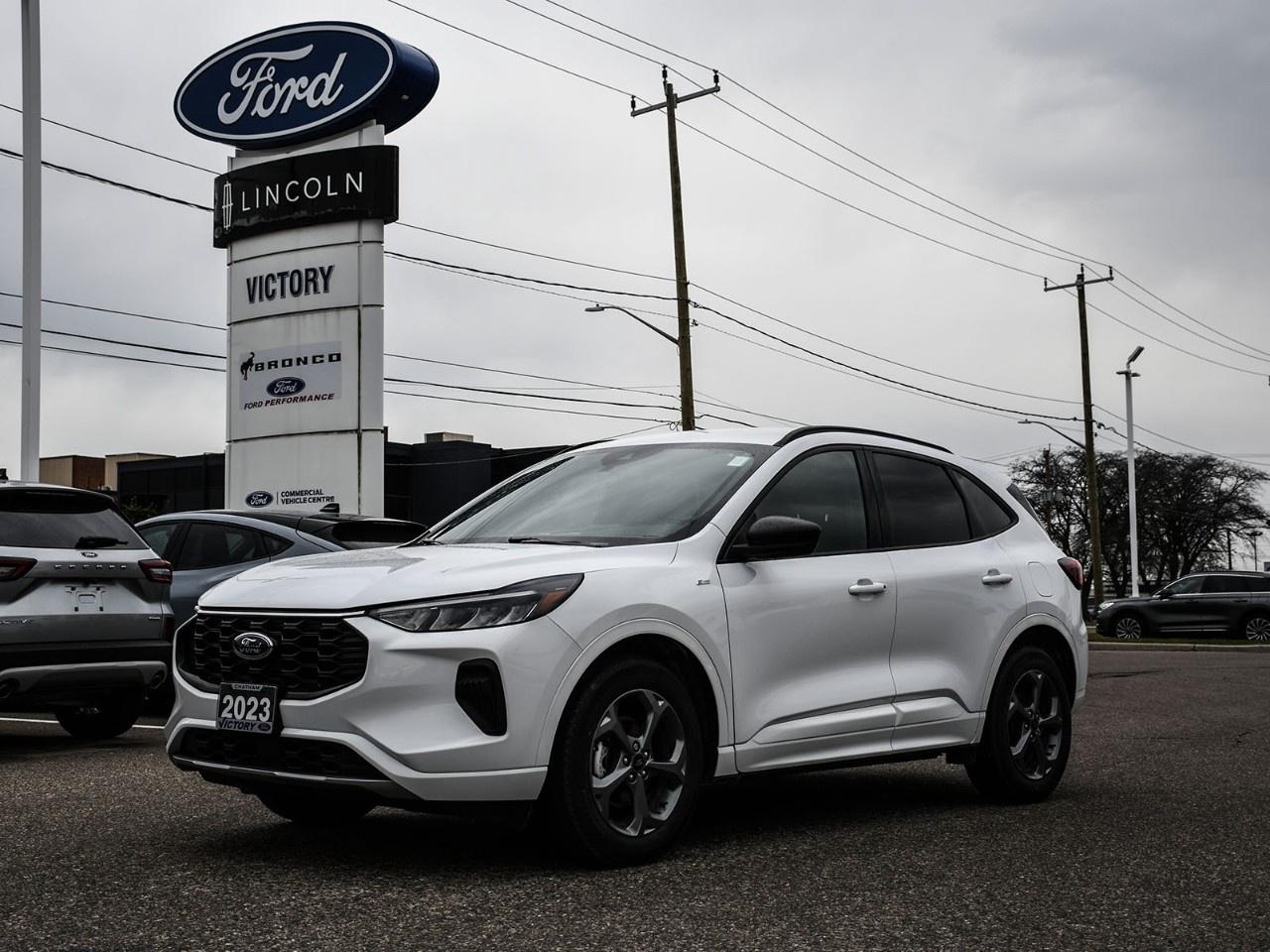 <h2>NOW AVAILABLE AT VICTORY FORD LINCOLN</h2><h1>2023 Ford Escape ST-Line AWD 300A</h1><h3>Cold Weather Package  Sporty ST-Line Styling  Intelligent AWD</h3><p>This 2023 Ford Escape ST-Line AWD 300A combines sporty styling with everyday practicality and all-season capability. With its aggressive ST-Line design, intelligent all-wheel drive system, and the added comfort of the Cold Weather Package, this Escape is ready to handle Canadian winters while delivering a fun and confident driving experience.</p><h3>POWER & PERFORMANCE</h3><ul><li><p>1.5L EcoBoost® Engine</p></li><li><p>8-Speed Automatic Transmission</p></li><li><p>Intelligent All-Wheel Drive (AWD)</p></li><li><p>Selectable Drive Modes</p></li><li><p>Smooth & Efficient Performance</p></li></ul><h3>ST-LINE STYLING</h3><ul><li><p>Unique ST-Line Sport Grille</p></li><li><p>Black Exterior Accents</p></li><li><p>Sport-Inspired Interior Design</p></li><li><p>Distinctive ST-Line Badging</p></li><li><p>Sport Cloth Seating with Red Stitching</p></li></ul><h3>COLD WEATHER PACKAGE</h3><ul><li><p>Heated Front Seats</p></li><li><p>Heated Steering Wheel</p></li><li><p>Heated Side Mirrors</p></li><li><p>Remote Start System</p></li></ul><h3>EXTERIOR FEATURES</h3><ul><li><p>LED Headlights</p></li><li><p>Rear Privacy Glass</p></li><li><p>Power Side Mirrors</p></li><li><p>Rear Spoiler</p></li><li><p>Alloy Wheels</p></li></ul><h3>INTERIOR & COMFORT</h3><ul><li><p>Dual-Zone Automatic Climate Control</p></li><li><p>Power Driver Seat</p></li><li><p>Spacious Cabin & Cargo Area</p></li><li><p>60/40 Split Folding Rear Seats</p></li></ul><h3>TECHNOLOGY</h3><ul><li><p>SYNC® 4 Infotainment System</p></li><li><p>Large Touchscreen Display</p></li><li><p>Apple CarPlay® & Android Auto</p></li><li><p>FordPass Connect with Wi-Fi Capability</p></li><li><p>Push Button Start</p></li><li><p>Multiple USB Charging Ports</p></li></ul><h3>SAFETY & DRIVER ASSISTANCE</h3><ul><li><p>Ford Co-Pilot360</p></li><li><p>Pre-Collision Assist with Automatic Emergency Braking</p></li><li><p>Blind Spot Information System (BLIS®)</p></li><li><p>Lane Keeping System</p></li><li><p>Rear View Camera</p></li><li><p>Automatic High Beams</p></li></ul><h3>HIGHLIGHTS</h3><ul><li><p>ST-Line 300A Equipment Group</p></li><li><p>Intelligent AWD Capability</p></li><li><p>Cold Weather Package</p></li><li><p>Sporty ST-Line Design</p></li><li><p>Advanced SYNC® 4 Technology</p></li></ul><h3>Special Offer:</h3><p><strong>Peace of Mind Included:</strong> 3-Month Comprehensive Warranty (for vehicles under 10 years old & under 160,000 km) No-Haggle, Live Market Pricing  Transparent & Competitive All-Inclusive Pricing: Fees, Reconditioning, and Full Detailing Included (Taxes & Licensing Extra)</p><h4>Additional Details:</h4><p><strong>Keys:</strong> Standard with one key. Additional keys (if provided by the previous owner) included at no cost. Optional key purchases available upon request.</p><p><strong>Visit Victory Ford Lincoln Today</strong> Schedule your appointment to experience this exceptional vehicle.</p>