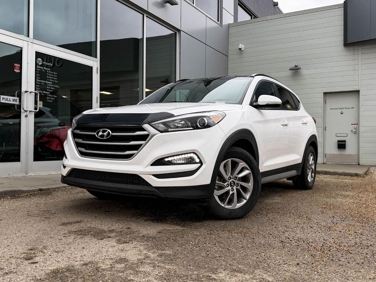 Discover reliability and style with this pre-owned 2017 Hyundai Tucson SE AWD in classic White with a sleek Black leather interior. Powered by a 2.0L GDI I4 engine paired with a smooth 6-speed automatic transmission and an advanced all-wheel-drive system, it delivers confident performance and handling in all conditions.Enjoy comfort and convenience with heated front seats, dual-zone automatic climate control, and a user-friendly AM/FM/XM/CD/MP3 audio system with steering wheel controls. Safety is prioritized with features like hill start assist, rearview camera, multiple airbags, and stability control.This Tucson SE also boasts 17-inch alloy wheels, LED daytime running lights, and a spacious cargo area with smart storage solutions, making it ideal for daily commutes and weekend adventures alike.With strong build quality and a comprehensive feature set, this 2017 Hyundai Tucson SE AWD offers excellent value and dependable performance  schedule your test drive today and experience it firsthand!Go Mazda is an AMVIC licensed business.This vehicle was previously used as a Rental.