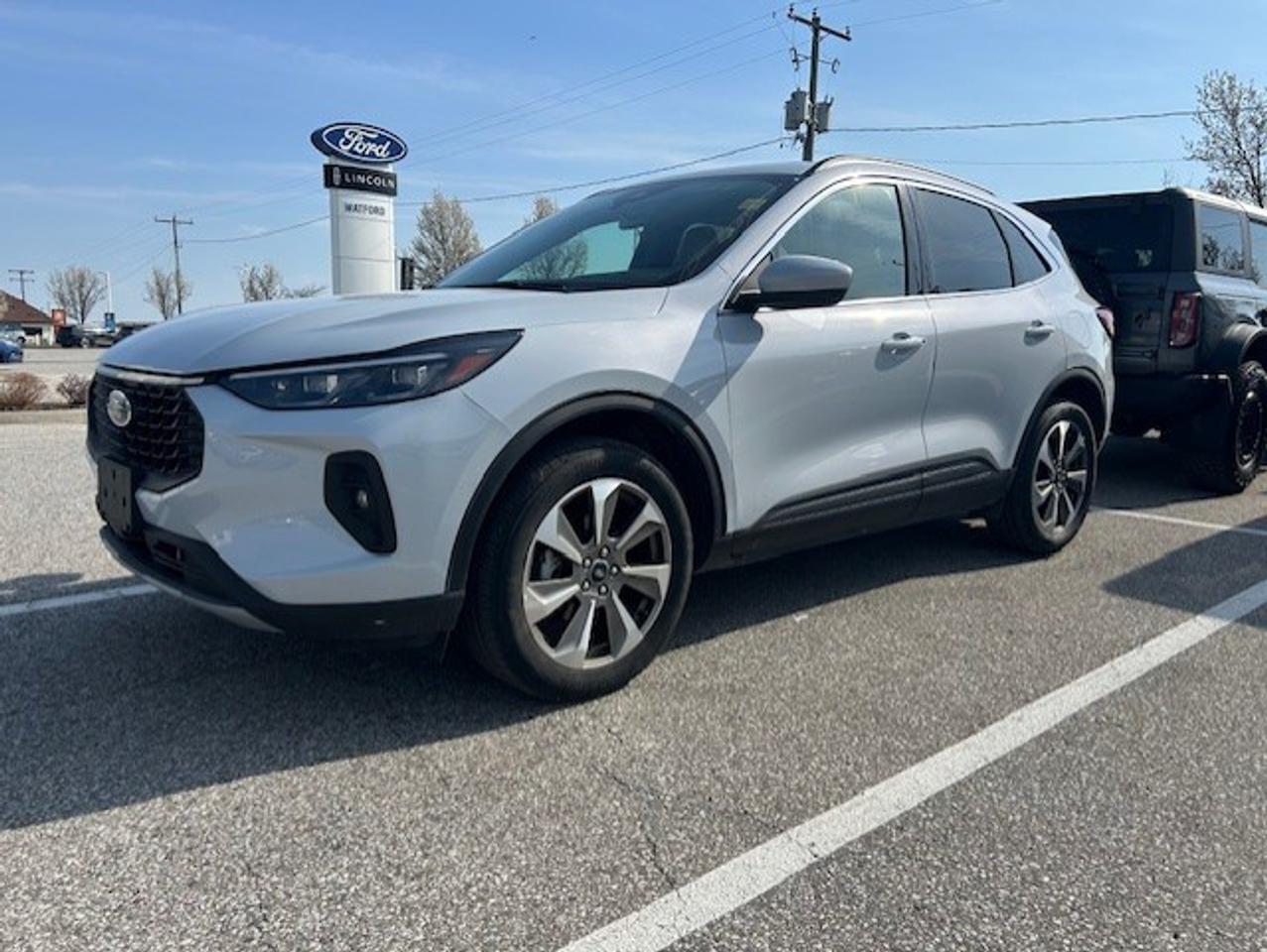 Discover a refined and practical compact SUV at Watford Ford with this used 2025 Ford Escape Platinum. Finished in Silver with an automatic transmission, it offers a clean, modern look and easy daily driving. With 32,454 km on the odometer, this Escape Platinum is ready for commutes, errands, and weekend travel.

This 2025 Ford Escape Platinum blends comfort, smart design, and everyday usability in a size that fits city streets and highways with ease. Its polished appearance and versatile cabin make it a strong choice for drivers who want upscale feel without giving up flexibility or efficiency.

FEATURES OF THE Escape Platinum

»» Premium trim with upscale design details
»» Automatic transmission for smooth daily driving
»» Silver exterior with clean modern look
»» Compact SUV versatility for active lifestyles

ADVANCED SAFETY FEATURES

»» Built with Ford safety-focused vehicle engineering
»» Elevated SUV view aids driver awareness
»» Responsive handling supports confident road manners
»» Designed for family-friendly everyday peace of mind

PERFORMANCE AND EFFICIENCY

»» Automatic transmission delivers smooth gear changes
»» Compact SUV size supports easy manoeuvring
»» Balanced ride for city and highway
»» 32,454 km shows measured vehicle use

COMFORT AND CONVENIENCE

»» Spacious cabin supports daily passenger comfort
»» Four-door access helps easy entry
»» Practical layout suits errands and travel
»» Elevated seating adds comfort and visibility

TECHNONOLGY AND CONNECTIVITY

»» Driver-focused controls are easy to reach
»» Clear instrument layout supports quick reading
»» Modern cabin design feels intuitive daily
»» Well-organized dash promotes simple operation

CARGO SPACE

»» Rear cargo area suits daily gear
»» SUV design supports flexible storage needs
»» Practical space for shopping and luggage
»» Cabin layout helps carry passengers comfortably

WHAT OTHER OWNERS LIKE

»» Easy-to-drive size for mixed driving needs
»» Comfortable ride during daily commuting duties
»» Useful cargo room for active lifestyles
»» Quiet, refined feel in compact SUV

The 2025 Ford Escape Platinum stands out for drivers who want a premium feel in a manageable SUV package. Its Silver exterior gives it a fresh and upscale presence, while the automatic transmission helps make every drive smooth and relaxed. This is a vehicle that feels at home in town, on the highway, and everywhere between.

Inside and out, this 2025 Ford Escape Platinum is built to suit modern life. It offers the flexibility many drivers need, with passenger space, cargo utility, and a comfortable driving position that works well every day. It is an excellent fit for small families, commuters, or anyone moving up to a well-equipped compact SUV.

Available now at Watford Ford in Watford, this used 2025 Ford Escape Platinum delivers style, versatility, and confidence in one smart package. With 32,454 km, it offers a great opportunity to enjoy a newer SUV that still has plenty to give.

This 2025 Ford Escape Platinums VIN is: 1FMCU9JA4SUA73585.

PREVIUOS DAILY RENTAL